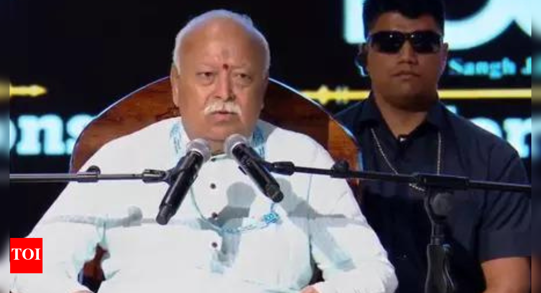 RSS chief Mohan Bhagwat defended the organization’s status as a body of individuals, questioning the need for registration with the British government and highlighting post-independence recognition. He also addressed the ‘Love Jihad’ concept, attributing its perceived success to a failure in imparting Hindu values to children, while cautioning against generalizing about the Muslim community. RSS Chief Mohan Bhagwat NEW DELHI: RSS chief Mohan Bhagwat on Sunday addressed criticisms about the organisation’s registration status, stating that RSS is officially recognised as a body of individuals, after Congress questioned its operations.”RSS was established in 1925, so do you expect us to have registered with the British government?” Bhagwat responded during a RSS-organised question and answer session.He clarified that post-independence, the Government of India did not mandate registration, and RSS is officially categorised and recognised as a body of individuals. Bhagwat further noted that both the Income Tax department and courts have acknowledged RSS as a body of individuals, granting them tax exemption. “We were banned thrice. So government has recognised us. If we were not there, whom did they ban?” Bhagwat pointed out.He further stated that many entities remain unregistered, citing “Even Hindu Dharma is not registered” as an example.Addressing allegations about flag preferences, Bhagwat explained that while saffron holds special significance in RSS as a Guru, they maintain deep respect for the Indian tricolour. “We always respect, offer tribute and protect our tricolour,” he affirmed.These statements followed Congress president Mallikarjun Kharge’s recent call for RSS ban. Additionally, his son and Karnataka Minister Priyank Kharge sought prohibition of RSS activities in government institutions and public spaces, questioning their registration details and funding sources.Support to political partiesBhagwat addressed various other topic included RSS’ political affiliation. On being asked why Sangha does not support any political party, he said, “We do not support any political party. We do not participate in vote politics, current politics, or election politics. Sangha is a work of uniting society and politics, but by nature, it is divisive. So we keep out of politics. We support policies, and especially now that we are a force, we will exert our force to support the right policy. Not individual, not a party, but policy. For example, we wanted to have Ram Mandir in Ayodhya. So our Swayamsevaks supported those who stood by its construction. BJP was there, but if Congress had supported that, our Swayamsevaks would have voted for that party also.”Further asserting his stance, he added, “We don’t have special affinity towards one party. There is no Sangh party. No party is ours, and all parties are ours because they are Bharatiya parties. We support Rashtraneeti, not Rajneeti. We do that publicly. We have our views, and we want to take this country in a particular direction. Those who will drive in that direction particularly, we will support them. We’ll ask the public to think about this and support them. Whatever the public does, it is their prerogative, but we will exert our strength in favour of the Rashtraneeti we feel proud of.”‘Love Jihad, how can that be?’ asks RSS chief BhagwatApart from the registration row, Mohan Bhagwat on Sunday also questioned “love Jihad”. “Love Jihad, how can that be? A girl or boy reared in our Hindu sanskaars as our own, blood of our blood, is led astray by someone outside due to petty attractions. That is our lack. Giving ‘sanskaars’ and ‘maryada’ to our children is our responsibility. We have faltered in it, and the result is the success of Love Jihad… When we see these activities, we bracket the entire Muslim society into one category. That is not good. We are Hindus. We do not think like that,” he said.About the AuthorTOI News DeskThe TOI News Desk comprises a dedicated and tireless team of journalists who operate around the clock to deliver the most current and comprehensive news and updates to the readers of The Times of India worldwide. With an unwavering commitment to excellence in journalism, our team is at the forefront of gathering, verifying, and presenting breaking news, in-depth analysis, and insightful reports on a wide range of topics. The TOI News Desk is your trusted source for staying informed and connected to the ever-evolving global landscape, ensuring that our readers are equipped with the latest developments that matter most.”Read MoreEnd of ArticleFollow Us On Social MediaVideosEvery Indian Shares Ancestral Roots, No ‘Ahindu’ Exists: Mohan BhagwatFormer Army Commander Warns of Rising Extremist Threat from BangladeshPM Modi Highlights Legal Reforms, Stresses Need for Law in Local Languages‘Rallies Cancelled Due to Low Response’ Congress Responds to PM’s ‘Reject Katta Sarkar…’ RemarkMohsin Naqvi Cornered At ICC Meet In Dubai; Asia Cup Trophy Dispute Turns Into Diplomatic Face-Off‘Bulldozer Will Roll Over Corruption’: Yogi Adityanath’s Fierce Attack on RJD-Congress’Modi Runs Empire Of Fear, We’re Fighting Mahatma’s Battle’: Priyanka Gandhi Targets PM In BiharDeadlock Deepens: Afghanistan Calls Pakistan Irresponsible As Peace Talks Break Down Once AgainPM Modi’s ‘65-Volt Jhatka’ Jibe Rocks Bihar Rally, Mocks Rahul’s Pond Dive As ‘Doobne Ki Practice’From Canada To New Zealand, The World Sings Along As India’s National Song ‘Vande Mataram’ Turns 150123PhotostoriesFrom ‘Sardar Udham’ to ‘Sam Bahadur’: Vicky Kaushal’s top movies to watch on OTT9 emotional animals that show love and grief just Like humansFrom heated arguments with Divya Ganesh to special moments with Aurora: Evicted contestant Tushar’s Bigg Boss Tamil 9 journeyBollywood tales where virtue always triumphs over darknessBollywood tales where revenge becomes a path to redemption and inner change5 smart ways to spend the most wholesome time with partnerEver noticed this face above temple doors? The powerful story of Shiva’s ‘Kirtimukha’From better skin to improved mental health: 6 benefits of eating an orange everydayMust-watch K-dramas: From ‘Last Summer’ to ‘Dynamite Kiss’, new releases heating up November 20255 reasons to consume Pomegranate Amla Juice daily123Hot PicksStock market holidayBank HolidayBihar Election 2025Gold rate todaySilver rate todayPublic Holidays NovemberBank Holidays NovemberTop TrendingMarshawn Kneeland Cause of DeathMLB Trade RumorsMLB Trade Rumors Detroit TigersMicah ParsonsFortnite OG Butterfly Live EventMarshawn Kneeland NewsNHL Injury UpdateBO Nix WifeNew Vande Bharat ExpressIndia World Cup Cash Prize