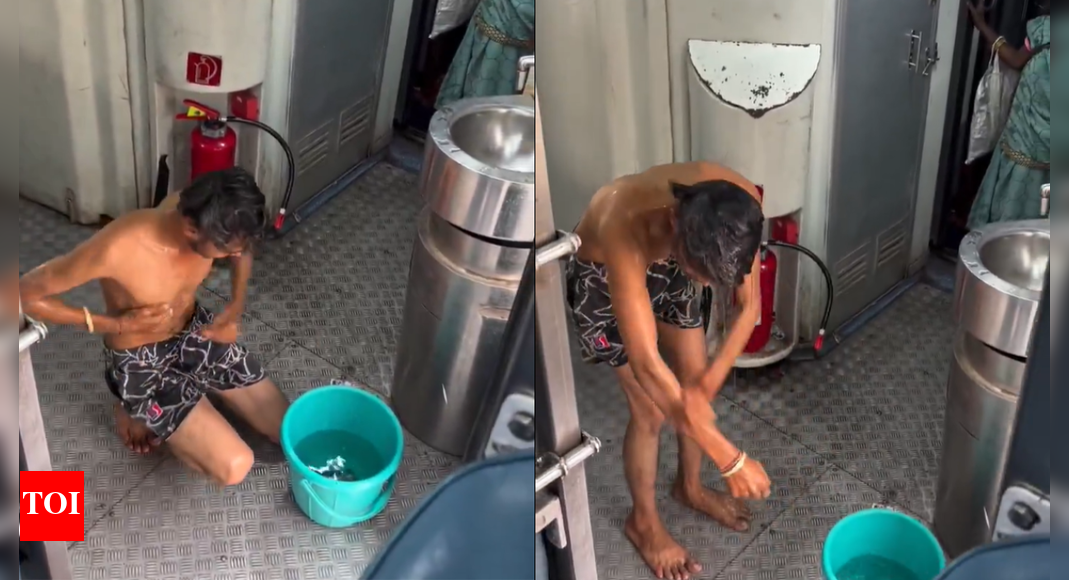 Watch: Passenger films bizarre bath on train; railways identifies man, takes action | India News