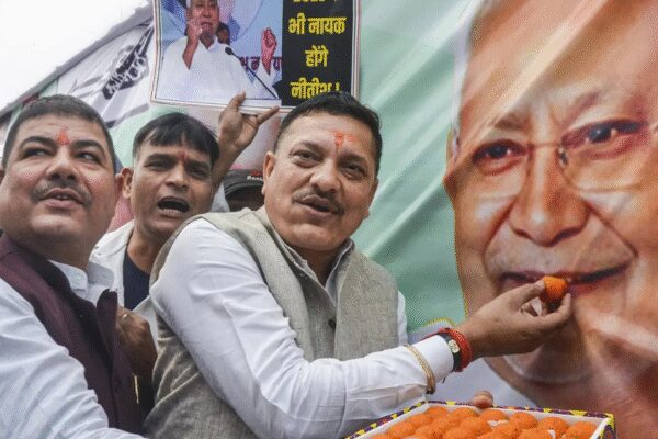 The National Democratic Alliance (NDA) surged past 200 seats in the Bihar Assembly polls, triggering jubilant celebrations at BJP and JD(U) offices. Trends showed the NDA, led by Nitish Kumar and Narendra Modi, dominating the opposition. This election marked a significant test for Nitish Kumar, with high voter turnout and a historic lack of violence. Workers celebrating as NDA crosses 200 mark (PTI image)  NEW DELHI: Celebrations broke out across Bharatiya Janata Party (BJP) and Janata Dal (United) offices on Friday afternoon as the National Democratic Alliance (NDA) surged past the 200-seat mark in the Bihar Assembly polls, according to Election Commission of India trends at 3.18 pm.The NDA, powered by chief minister Nitish Kumar’s JD(U) and Prime Minister Narendra Modi’s BJP is leading in 208 seats. BJP held leads in 95, JD(U) in 84, LJP in 20, HAM in 5 and RLM in 4.On the opposition side, the Mahagathbandhan trailed with the RJD ahead in 24 seats, Congress in 2, CPI(ML) in 1 and CPI-M in 1, taking their total to 28. BSP led in one seat, while AIMIM secured leads in six.Celebrations turn streets into carnivalsIn Patna, the mood turned electric as BJP workers arrived with a chariot carrying a large image of Prime Minister Modi. Election Results 2025Bihar election results: Bihar votes for ‘sushasan’; NDA cruising towards clean sweepBihar election results: Top winners and losersBihar election results: Maithili Thakur headed for big debutBiharAlliance ViewiParty ViewSeats: 243L + WMajority: 122NDA0MGB0OTH0Leads + Wins: 243/243NDA LEADINGExperience Bihar Election Results in 3D A new interactive way to explore constituenciesSource: PValueOne jubilant worker was heard saying, “Dhairya rakho mere bhagwan Modi par”. Supporters were seen dancing, singing and waving saffron flags.Party workers wore masks of PM Modi and Nitish Kumar, breaking into spontaneous performances as trends consistently placed the NDA ahead. Buckets of jalebi, litti chokha and other Bihar delicacies circulated among volunteers, while drums echoed through the JD(U) office where a giant poster of Nitish Kumar fluttered in the evening breeze.A young group marched proudly with JD(U)’s green thermocol arrow, chanting, “Teer chalega, Bihar badega! (The arrow will strike, Bihar will progress!)” Firecrackers carpeted the ground, streaked with green gulaal as senior workers, some sitting under makeshift tarpaulins, beat slow rhythms on the dholak.Delhi BJP HQ prepares Bihar menu for the victory nightAt the BJP headquarters in Delhi, workers made arrangements for victory celebrations with a full Bihari spread. A local confectioner confirmed: “We have sattu paratha, baingan chokha, jalebi… and litti chokha can also be prepared.”Meanwhile in Mokama, Rasgulla, litti chokha were also being prepared at the residence of RJD leader Veena Devi as counting intensified in her constituency.“NDA will cross 200”: A prediction turns realityEarlier in the morning, BJP minister and candidate Nitin Nabin expressed confidence, stating the NDA would outperform its 2010 showing and secure more than 200 seats.“We will get 200+ seats,” he said. Nabin addressed RJD as the “symbol of jungle raj.””They (RJD) are still not able to let go of their mindset of ‘jungle raj’. RJD is the symbol of ‘jungle raj’,” he said.A test of endurance for Nitish KumarFor chief minister Nitish Kumar, who has governed Bihar for nearly two decades, this election was widely viewed as a test of public trust. Despite criticisms and shifting alliances, the trends signalled a renewed endorsement of his governance model.His supporters credited the results to his focus on rural development, social schemes, improved infrastructure and what they call a stable administrative approach.The 2025 Bihar election made history with zero repolling and zero incidents of violence, a stark contrast to earlier decades that saw widespread unrest. Voter turnout also reached record levels, with 67.13% overall polling across two phases. This is Bihar’s highest turnout since 1951.Allies and analysts alike point to the combined force of PM Modi’s nationwide appeal and Nitish Kumar’s deep grassroots network as the key driver of the NDA’s resounding performance. The alliance centred its campaign on welfare delivery, infrastructure expansion, administrative stability and cultural identity, including PM Modi’s push for UNESCO recognition of Chhath Puja.About the AuthorTOI News DeskThe TOI News Desk comprises a dedicated and tireless team of journalists who operate around the clock to deliver the most current and comprehensive news and updates to the readers of The Times of India worldwide. With an unwavering commitment to excellence in journalism, our team is at the forefront of gathering, verifying, and presenting breaking news, in-depth analysis, and insightful reports on a wide range of topics. The TOI News Desk is your trusted source for staying informed and connected to the ever-evolving global landscape, ensuring that our readers are equipped with the latest developments that matter most.”Read MoreEnd of ArticleFollow Us On Social MediaVideosFirst-Time Woman Voter in Danapur Explains Why Nitish Kumar Scored Massive Landslide Win in BiharIndia Negotiating Multiple FTAs To Boost Free Flow Of Capital And Trade: Piyush Goyal‘Not Just Congress’: Tharoor Calls Out RJD Amid NDA’s Big Bihar Lead‘Pak Ready For Two-Front War’: Khawaja Asif’s Hollow Threat To India After Islamabad BlastCDS Anil Chauhan Issues Red Line To Defence Industry, Warns Against Delays And OverpromisingWashington Reports Encouraging Momentum As India-US Trade Talks Advance Toward A Year-End AgreementAsim Munir Steps In Amid Islamabad Terror Attack, Persuades Sri Lanka To Continue With Cricket Tour‘No Impunity For Terrorists’: Shashi Tharoor Endorses Govt Probe As Red Fort Blast Claims 13th LifeDelhi Blast: Security Forces Demolish House of Red Fort Bombing Accused Umar Nabi in Pulwama‘Not An Apologist For BJP’: Shashi Tharoor On Row Over Backing Modi Govt During Op Sindoor123PhotostoriesWhich Plant You Should Bring Home As Per Your Date of BirthMetabolic doctor reveals top 10 foods to reduce triglycerides naturally7 most colourful frog species in the worldAfter Bihar poll debacle, what’s next for Tejashwi Yadav and a shaken RJD?Diabetes: Lesser-known symptoms women should be careful aboutJubilee Hills bypoll twist: Congress triumphs, Revanth Reddy emerges as Telangana’s tallest leaderFrom heart to gut: Health benefits of eating water chestnutsHyderabad eyes global spotlight: Govt may rope in Lionel Messi as ‘Telangana Rising’ ambassadorNitish Kumar’s stunning mandate in Bihar: How the veteran leader silenced doubters once againCrowds but no votes: What went wrong with Rahul Gandhi’s Bihar election push?123Hot PicksAlinagar Election ResultRaghopur Election ResultBihar Election Result 2025Gold rate todaySilver rate todayPublic Holidays NovemberBank Holidays NovemberTop TrendingBihar Election CandidatesAlinagar Election ResultKargahar Election ResultPrashant KishorChirag PaswanAssembly Election BiharRaghopur Election ResultMahua Election ResultPune Bridge AccidentAnta Election Result