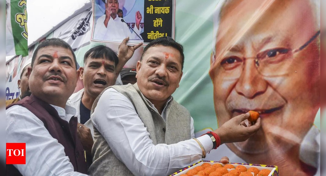 The National Democratic Alliance (NDA) surged past 200 seats in the Bihar Assembly polls, triggering jubilant celebrations at BJP and JD(U) offices. Trends showed the NDA, led by Nitish Kumar and Narendra Modi, dominating the opposition. This election marked a significant test for Nitish Kumar, with high voter turnout and a historic lack of violence. Workers celebrating as NDA crosses 200 mark (PTI image)  NEW DELHI: Celebrations broke out across Bharatiya Janata Party (BJP) and Janata Dal (United) offices on Friday afternoon as the National Democratic Alliance (NDA) surged past the 200-seat mark in the Bihar Assembly polls, according to Election Commission of India trends at 3.18 pm.The NDA, powered by chief minister Nitish Kumar’s JD(U) and Prime Minister Narendra Modi’s BJP is leading in 208 seats. BJP held leads in 95, JD(U) in 84, LJP in 20, HAM in 5 and RLM in 4.On the opposition side, the Mahagathbandhan trailed with the RJD ahead in 24 seats, Congress in 2, CPI(ML) in 1 and CPI-M in 1, taking their total to 28. BSP led in one seat, while AIMIM secured leads in six.Celebrations turn streets into carnivalsIn Patna, the mood turned electric as BJP workers arrived with a chariot carrying a large image of Prime Minister Modi. Election Results 2025Bihar election results: Bihar votes for ‘sushasan’; NDA cruising towards clean sweepBihar election results: Top winners and losersBihar election results: Maithili Thakur headed for big debutBiharAlliance ViewiParty ViewSeats: 243L + WMajority: 122NDA0MGB0OTH0Leads + Wins: 243/243NDA LEADINGExperience Bihar Election Results in 3D A new interactive way to explore constituenciesSource: PValueOne jubilant worker was heard saying, “Dhairya rakho mere bhagwan Modi par”. Supporters were seen dancing, singing and waving saffron flags.Party workers wore masks of PM Modi and Nitish Kumar, breaking into spontaneous performances as trends consistently placed the NDA ahead. Buckets of jalebi, litti chokha and other Bihar delicacies circulated among volunteers, while drums echoed through the JD(U) office where a giant poster of Nitish Kumar fluttered in the evening breeze.A young group marched proudly with JD(U)’s green thermocol arrow, chanting, “Teer chalega, Bihar badega! (The arrow will strike, Bihar will progress!)” Firecrackers carpeted the ground, streaked with green gulaal as senior workers, some sitting under makeshift tarpaulins, beat slow rhythms on the dholak.Delhi BJP HQ prepares Bihar menu for the victory nightAt the BJP headquarters in Delhi, workers made arrangements for victory celebrations with a full Bihari spread. A local confectioner confirmed: “We have sattu paratha, baingan chokha, jalebi… and litti chokha can also be prepared.”Meanwhile in Mokama, Rasgulla, litti chokha were also being prepared at the residence of RJD leader Veena Devi as counting intensified in her constituency.“NDA will cross 200”: A prediction turns realityEarlier in the morning, BJP minister and candidate Nitin Nabin expressed confidence, stating the NDA would outperform its 2010 showing and secure more than 200 seats.“We will get 200+ seats,” he said. Nabin addressed RJD as the “symbol of jungle raj.””They (RJD) are still not able to let go of their mindset of ‘jungle raj’. RJD is the symbol of ‘jungle raj’,” he said.A test of endurance for Nitish KumarFor chief minister Nitish Kumar, who has governed Bihar for nearly two decades, this election was widely viewed as a test of public trust. Despite criticisms and shifting alliances, the trends signalled a renewed endorsement of his governance model.His supporters credited the results to his focus on rural development, social schemes, improved infrastructure and what they call a stable administrative approach.The 2025 Bihar election made history with zero repolling and zero incidents of violence, a stark contrast to earlier decades that saw widespread unrest. Voter turnout also reached record levels, with 67.13% overall polling across two phases. This is Bihar’s highest turnout since 1951.Allies and analysts alike point to the combined force of PM Modi’s nationwide appeal and Nitish Kumar’s deep grassroots network as the key driver of the NDA’s resounding performance. The alliance centred its campaign on welfare delivery, infrastructure expansion, administrative stability and cultural identity, including PM Modi’s push for UNESCO recognition of Chhath Puja.About the AuthorTOI News DeskThe TOI News Desk comprises a dedicated and tireless team of journalists who operate around the clock to deliver the most current and comprehensive news and updates to the readers of The Times of India worldwide. With an unwavering commitment to excellence in journalism, our team is at the forefront of gathering, verifying, and presenting breaking news, in-depth analysis, and insightful reports on a wide range of topics. The TOI News Desk is your trusted source for staying informed and connected to the ever-evolving global landscape, ensuring that our readers are equipped with the latest developments that matter most.”Read MoreEnd of ArticleFollow Us On Social MediaVideosFirst-Time Woman Voter in Danapur Explains Why Nitish Kumar Scored Massive Landslide Win in BiharIndia Negotiating Multiple FTAs To Boost Free Flow Of Capital And Trade: Piyush Goyal‘Not Just Congress’: Tharoor Calls Out RJD Amid NDA’s Big Bihar Lead‘Pak Ready For Two-Front War’: Khawaja Asif’s Hollow Threat To India After Islamabad BlastCDS Anil Chauhan Issues Red Line To Defence Industry, Warns Against Delays And OverpromisingWashington Reports Encouraging Momentum As India-US Trade Talks Advance Toward A Year-End AgreementAsim Munir Steps In Amid Islamabad Terror Attack, Persuades Sri Lanka To Continue With Cricket Tour‘No Impunity For Terrorists’: Shashi Tharoor Endorses Govt Probe As Red Fort Blast Claims 13th LifeDelhi Blast: Security Forces Demolish House of Red Fort Bombing Accused Umar Nabi in Pulwama‘Not An Apologist For BJP’: Shashi Tharoor On Row Over Backing Modi Govt During Op Sindoor123PhotostoriesWhich Plant You Should Bring Home As Per Your Date of BirthMetabolic doctor reveals top 10 foods to reduce triglycerides naturally7 most colourful frog species in the worldAfter Bihar poll debacle, what’s next for Tejashwi Yadav and a shaken RJD?Diabetes: Lesser-known symptoms women should be careful aboutJubilee Hills bypoll twist: Congress triumphs, Revanth Reddy emerges as Telangana’s tallest leaderFrom heart to gut: Health benefits of eating water chestnutsHyderabad eyes global spotlight: Govt may rope in Lionel Messi as ‘Telangana Rising’ ambassadorNitish Kumar’s stunning mandate in Bihar: How the veteran leader silenced doubters once againCrowds but no votes: What went wrong with Rahul Gandhi’s Bihar election push?123Hot PicksAlinagar Election ResultRaghopur Election ResultBihar Election Result 2025Gold rate todaySilver rate todayPublic Holidays NovemberBank Holidays NovemberTop TrendingBihar Election CandidatesAlinagar Election ResultKargahar Election ResultPrashant KishorChirag PaswanAssembly Election BiharRaghopur Election ResultMahua Election ResultPune Bridge AccidentAnta Election Result