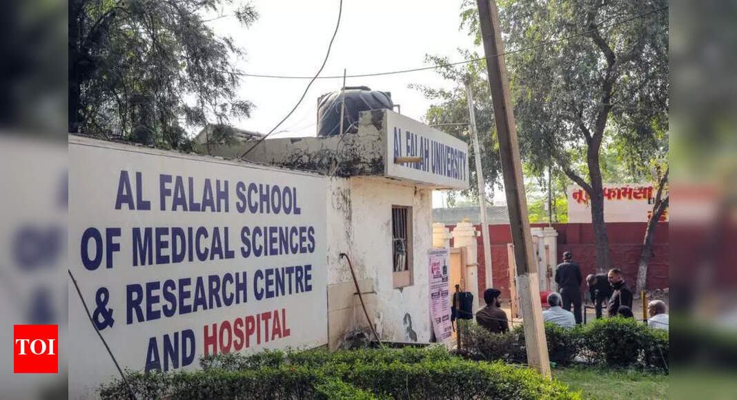 New Delhi: The crime branch of Delhi Police has filed two FIRs against Al-Falah University for alleged offences of cheating and forgery, and searched its premises in Delhi and Faridabad. Police have also issued a notice to the university seeking certain documents, sources said.Meanwhile, the special cell, which is probing a deeper conspiracy behind Monday’s car bomb blast near Red Fort, carried out raids and searches on premises linked to the university and doctors from there, besides six locations in Nuh. Six people, including two doctors and a cleric, have been detained.One of the doctors, picked up from Ahmadbas village in Haryana’s Mewat district, was asked if alleged bomber Dr Umar Un Nabi had met him before the blast. Umar’s location, while he was on his way from Ferozepur Jhirka to Delhi, came near this village, an officer said.The other doctor belongs to Pathankot and had worked at the university in 2020-21. “The doctor was in telephonic communication with staff posted at Al-Falah University. It is being examined whether he was in touch with Umar,” said an officer. The university-cum-hospital, located at Dhauj in Haryana’s Faridabad district, has been at the centre of the blast investigation following the arrest of its doctors. Umer worked at its hospital. The investigation has revealed that room no. 13 in building no. 17 of the university was used as a key hideout where the blast plan was hatched and explosive materials were gathered, said sources.The two FIRs, the crime branch said, were registered following complaints and actions initiated by University Grants Commission and National Assessment and Accreditation Council (NAAC). Both bodies have flagged serious irregularities at the university in their assessment and inquiry reports. On Thursday, NAAC also issued a show-cause notice to Al-Falah University for displaying false accreditation on its website. “The first FIR has been lodged for cheating while the second FIR pertains to the alleged false accreditation claims,” a senior officer said. The university website says it was established by the Haryana assembly under Haryana Private Universities Act. According to the NAAC notice: “Al-Falah University, which is neither accredited nor applied for accreditation by NAAC, has publicly displayed on its website that it is an endeavour of Al-Falah Charitable Trust, which has been running three colleges on the campus, namely Al-Falah School of Engineering and Technology (since 1997, Graded A by NAAC), Brown Hill College of Engineering and Technology (since 2008), and Al-Falah School of Education and Training, Graded A by NAAC.” It called the claims “absolutely false and akin to misleading the public, especially the parents, students and stakeholders”.About the AuthorAbhayAbhay is a Special Correspondent at The Times of India, Delhi, with extensive experience in investigative journalism. Since 2014, he has been covering crime and prisons, providing in-depth analysis and thought-provoking reports.Read MoreEnd of ArticleFollow Us On Social MediaVideos’MMC’: PM Modi Mocks Congress After NDA’s Bihar Win; Calls It ‘Muslim League Maoist’ Party‘Abandoned Tribals To Their Fate’: PM Modi Accuses Congress Of Neglecting Tribal CommunitiesCDS General Anil Chauhan Highlights Inter-Service Jointness And Integration In Op SindoorEAM Jaishankar, Russian FM Lavrov To Hold Talks In Moscow On Nov 17 Ahead Of Putin’s India TripAir Marshal AK Bharti Reveals Why India Ended Operation Sindoor After Achieving Its Core ObjectiveWTO DG Okonjo-Iweala Lauds India’s Trade Strategy, Calls For Multilateral LeadershipPakistan Rejects Taliban Narrative And Says Rising Terror From Afghan Soil Can No Longer Be IgnoredNDA Sweeps Bihar, Nitish Kumar Prepares for 10th CM Oath; A Look Back at ‘Sushasan Babu’s’ JourneyPiyush Goyal Says India Ready For WTO Leadership, Rejects Reform Agendas Pushed By Developed NationsJ&K Police Confirm 9 Killed in Nowgam Blast After Explosives Recovered From Faridabad Blows Up123Photostories5 must-have pieces for a winter capsule wardrobeMahesh Babu to Priyanka Chopra: 5 best celebrity looks of the day5 easy exercises for shoulder painreliefSmelling this fragrance can instantly improve focus and supercharge the brain, and no, it’s not coffee6 easy and science-backed snacks that fight colon cancerMold Toxicity: How to recognize its symptoms that appear like a common cold7 phrases parents can say instead of ‘No’ to kidsExclusive – Bigg Boss 19: Mridul Tiwari reacts to his eviction, calls Farrhana Bhatt ‘toxic’ and ‘evil’, and comments on Amaal Mallik’s image being ‘white-washed’Animal protein vs plant protein: Which is best for meeting the body’s nutritional needs?10 phrases parents should never tell a child123Hot PicksAlinagar Election ResultRaghopur Election ResultBihar Election Result 2025Gold rate todaySilver rate todayPublic Holidays NovemberBank Holidays NovemberTop TrendingCarey Price WifeArjun TendulkarTyreek HillsDubai Prince Sheikh Hamdan Net WorthZack RyderPat NarduzziJack DohertyWayne Gretzkys SonDak PrescottPercy Harvin