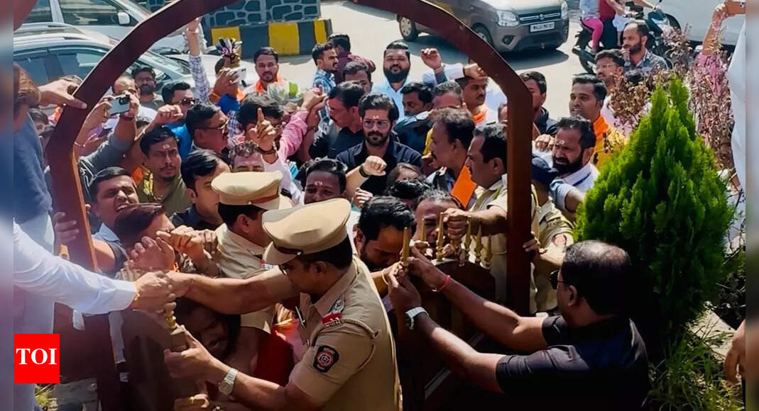 Amit Thackeray (in black) NAVI MUMBAI: Nerul police have filed an FIR against Amit Thackeray, the son of MNS chief Raj Thackeray and 70 MNS workers including office bearers for defying police prevention and forcibly unveiling the statue of Chhatrapati Shivaji Maharaj in a canopy constructed by NMMC at a junction in sector -1, Nerul near Rajiv Gandhi flyover on Sunday afternoon.The accused have been booked under relevant sections of BNS for assault or criminal force against a public servant, voluntarily causing hurt to a public servant in the discharge of their duty, unlawful assembly, rioting, joint liability and mischief causing loss or damage to property along with relevant sections of Maharashtra Police Act. The accused are Amit Thackeray, chief of Maharashtra Vidyarthi Sena, Mumbai, Gajanan Kale, MNS President of Navi Mumbai City and Abhijit Desai, MNS Nerul unit chief among other MNS workers, informed Brahmanand Naikwadi, senior inspector of Nerul.Inspector Naikwadi said, “The accused had took out a morcha without permission and gathering unlawfully assaulted the on-duty Assistant police inspector Nilesh Chavan and also created obstruction in government work by disregarding the instructions given by the police and also maliciously damaged the net installed around the statue by NMMC.”During his visit to Nerul, Amit Thackeray got annoyed after seeing that the statue of Maratha King was covered in a cloth on which dust had accumulated, as NMMC had delayed the unveiling since Feb last year.As Nerul police learnt that Amit Thackeray was going to unofficially unveil the statue, a police team from Nerul was deployed at the spot to prevent the unofficial unveiling of the statue of Maratha King. But, the MNS workers accompanying Thackeray vehemently protested defying the police prevention and forcibly reached the canopy and tore apart the cloth covering the statue after which Thackeray himself washed the statue. Gajanan Kale, MNS President of Navi Mumbai said, “Despite repeated communication with NMMC since Feb last year demanding unveiling of the statue of Chhatrapati Shivaji Maharaj at Nerul chowk built with an expenditure of around Rs 46 lakhs, the concerned civic authorities have been ignoring as probably they are waiting for appointment of CM Devendra Fadnavis. As the cloth used to cover the statue had become dirty, it was indeed desecration of the statue of Maratha king. Hence, Amit Thackeray took the lead to unveil the statue and himself washed the statue.”NMMC has released a presser stating that, the unveiling the statue of Chhatrapati Shivaji Maharaj in Nerul was not done by NMMC. Actually, the construction work around the statue has not been completed yet and is in the final stages. Therefore, the ceremonial installation of the statue was to be announced soon. Unveiling the statue without taking permission from the concerned authority and without giving any prior notice is very wrong and unauthorized from the point of view of law and order.End of ArticleFollow Us On Social MediaVideosNIA Arrests Alleged Aide Of ‘Suicide Bomber’ Umar Nabi In Delhi Terror AttackEAM Jaishankar Meets Qatar’s Top Leadership In Doha, Reaffirms Commitment To Stronger TiesSGPC Mulls Banning Lone Women In Pilgrim Jathas After ‘Missing’ Punjab Woman Marries Pakistani ManRSS-Linked Youth Shot Dead In Punjab’s Firozpur, Probe UnderwayKerala: RSS Worker Dies By Suicide After BJP Denies Local Body Poll Ticket In Thiruvananthapuram1 Dead, Several Feared Trapped As Portion Of Stone Mine Collapses In UP’s Sonbhadra; Rescue Ops On”I have no family…” Rohini Acharya Cuts Ties With Lalu Clan, Exits Politics Post-RJD DefeatRK Singh Slams Bihar BJP Suspension, Says He Only Opposed Tickets to Criminal Candidates‘Premature to Speculate’: Tharoor Hits Back at Farooq Abdullah Over Operation Sindoor Remarks‘Nitish Still X-Factor’ Pavan Verma Decodes Why Jan Suraaj Couldn’t Break Through in Bihar Polls123Photostories5 home exercises for Parkinson’s diseaseJournaling for beginners: 5 simple ways to start your de-stress journey5 ways to deepen connection without sending long emotional texts7 Cs of a champion mindset to drive success7-day infused water challenge that will reduce blood sugar levelsHow Bollywood actress Deepika Padukone inspires modern moms with grace and strength5 unsung women freedom fighters of the Indian race to Independence5 most expensive foods in the worldUnseen childhood pictures of Shraddha Kapoor with Shakti Kapoor, Siddhant, and Lata Mangeshkar you can’t miss5 timeless Swami Vivekananda quotes to inspire students on their journey123Hot PicksAlinagar Election ResultRaghopur Election ResultBihar Election Result 2025Gold rate todaySilver rate todayPublic Holidays NovemberBank Holidays NovemberTop TrendingKayla NicoleArjun TendulkarJames Harden girlfriendDubai Prince Sheikh Hamdan Net WorthRCB IPL RetentionBengaluru Techie Shoes MissingUS VisaIslam makhachev net worthDelhi BlastCharlie Mcavoy Injury