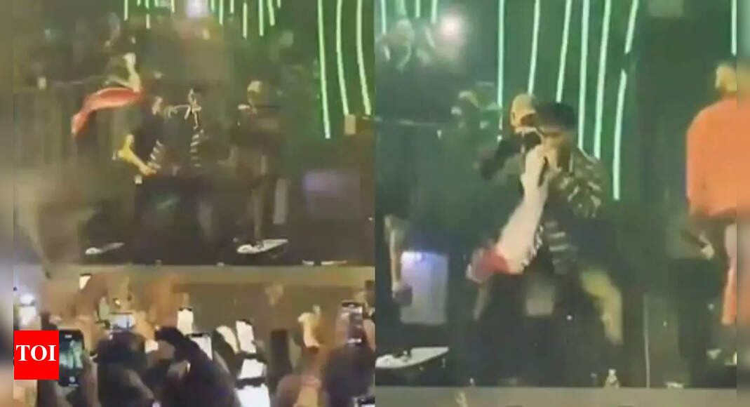 Pakistani rapper Talha Anjum caused a stir by waving the Indian flag during a concert in Nepal.  He later defended his actions, stating his art has no borders and he does not care about propaganda.  While some Pakistanis criticised the move, many Indians praised the gesture. The incident has generated significant social media discussion. Pakistani rapper Talha Anjum caused a stir by waving the Indian flag during a concert in Nepal.  He later defended his actions, stating his art has no borders and he does not care about propaganda.  While some Pakistanis criticised the move, many Indians praised the gesture. The incident has generated significant social media discussion. Pakistani Rapper Talha Anjum sparked a social media storm this weekend after he waved, and draped himself in the Indian flag during a performance in Nepal.According to The Dawn, Anjum was performing Kaun Talha, his diss track aimed at Indian rapper Naezy, when someone from the crowd threw the Indian tricolour towards him. The video shared widely on social media shows him grabbing the tricolour, waving it before wrapping it around himself.After facing criticism on social media, Anjum responded, saying, “My heart has no place for hate. My art has no borders. If my raising an Indian flag sparks controversy, so be it. I’ll do it again. I will never care about the media, the war-mongering governments, and their propaganda. Urdu rap is and will always be borderless.”As the video went viral, Anjum faced a wave of criticism on social media. One Pakistani user wrote, “Talha Anjum waving the Indian flag at a Nepal concert while India blocks his Spotify and likely his YouTube is a sad reminder of our own national decay. No pride, no dignity… just performers desperate for applause from those who shut them out.”Indian users, on the other hand, praised the gesture. One comment read, “The goodness of India will always spread to good people across.”About the AuthorTOI News DeskThe TOI News Desk comprises a dedicated and tireless team of journalists who operate around the clock to deliver the most current and comprehensive news and updates to the readers of The Times of India worldwide. With an unwavering commitment to excellence in journalism, our team is at the forefront of gathering, verifying, and presenting breaking news, in-depth analysis, and insightful reports on a wide range of topics. The TOI News Desk is your trusted source for staying informed and connected to the ever-evolving global landscape, ensuring that our readers are equipped with the latest developments that matter most.”Read MoreEnd of ArticleFollow Us On Social MediaVideosED Cracks Down On ‘White-Collar Terror Module’, Conducts 25 Raids Linked To Al-Falah UniversityUN Rejects ICT Verdict on Sheikh Hasina’s Death Penalty, But Backs Justice For Bangladesh VictimsPM Modi Reveals Why NDA Swept Bihar, Says Emotional Mode And 24×7 Development Win Elections In IndiaCalm And Radical: Dr Umar’s Pre-Blast Video Exposes Educated New Face Of Terror Behind Delhi Attack”Justice at Last”: Ousted PM Sheikh Hasina Gets Death Penalty; Victims Welcome VerdictJaishankar, Russian FM Lavrov Hold Key Talks in Moscow Ahead of Putin’s India Visit ‘In 3 Weeks’India Doubles Down On Russian Oil Imports Despite U.S. Sanctions HeatBangladesh Seeks Hasina’s Return As India Notes ICT Tribunal Verdict, Calls For Peace And Stability’This Generation Can Bring Viksit Bharat Before 2047’: Army Chief Dwivedi’s Message To Gen ZHasina Verdict Sparks Outrage as Ex-Indian Envoy Questions Evidence and Awami League Cries Black Day123PhotostoriesHow to talk to teens so they actually listen12 best US family-friendly destinations for Christmas 2025Bobby Deol, Pratik Gandhi, to Mrunal Thakur: How ‘Scam 1992’, ‘Aashram’ and ‘Scoop’ transformed these actors’ careersBigg Boss 19: From Kunickaa Sadanand, Amaal Mallik to Gaurav Khanna; Educational qualifications of top 9 contestantsThe silent night-time disorder linked to diabetes, BP, and heart attacks: Why snoring may signal a silent, dangerous disorderTop 7 baby boy names inspired by Lord HanumanSubtle signs you didn’t realize indicate calcium deficiency (and it can be life-threatening)Sugar or salt: Which one hurts the heart more?How to use the 55×5 manifestation rule to attract what you desire quickly and accuratelyHow to reduce sugar in a child’s diet (and why)123Hot PicksDelhi AQI TodaySheikh Hasina VerdictBihar Government FormationGold rate todaySilver rate todayPublic Holidays NovemberBank Holidays NovemberTop TrendingDak Prescott FianceBomb Threat TodayCeeDee LambDenver Nuggets vs chicago bullsKike HernndezDetroit Tigers WifeAuston MatthewsGiannis AntetokounmpoWWE Survivor SeriesWho is Ella Hakkinen