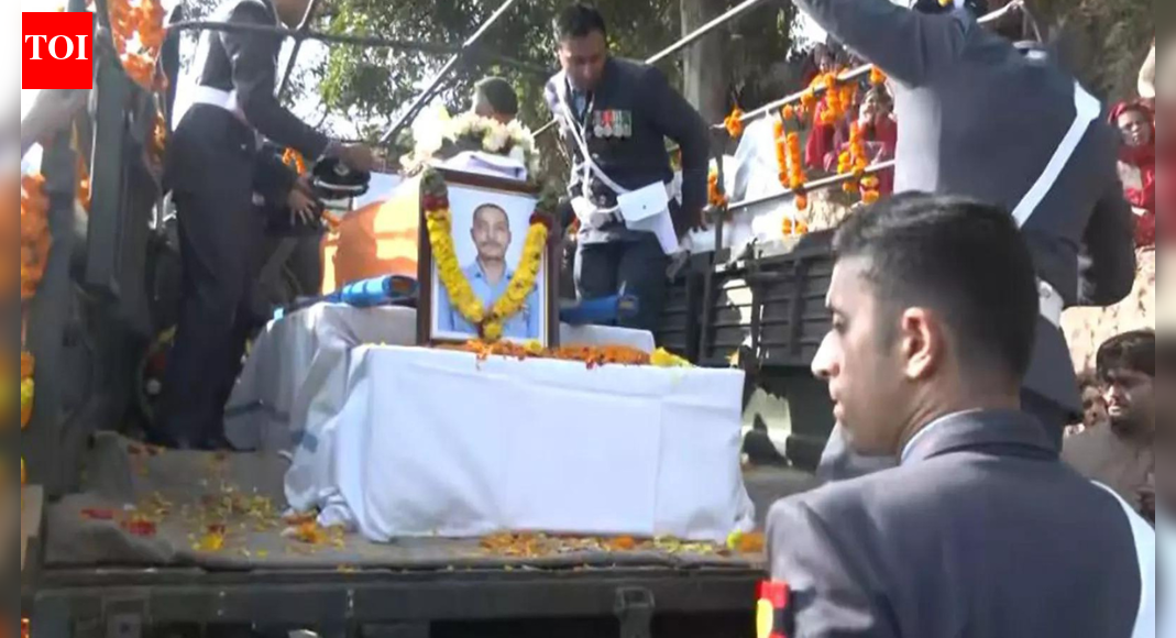 Wing Commander Namansh Syal, a decorated IAF pilot, tragically lost his life in a Tejas jet crash during the Dubai Air Show. His mortal remains were brought to his Himachal Pradesh village for final rites. Syal, a proud son of Kangra, was known for his bravery and dedication. The nation mourns this brave pilot. Mortal remains of Wing Commander Namansh Syal reach his native village in Kangra (ANI image)  NEW DELHI: The mortal remains of Wing Commander Namansh Syal, who lost his life in the Tejas fighter jet crash during the Dubai Air Show 2025, were brought to his native village of Patialkar in Himachal Pradesh’s Kangra district on Sunday.Villagers, family members and officials gathered to pay emotional tributes as his last rites are set to be performed.The Indian Air Force (IAF) confirmed the pilot’s demise after the aircraft crashed and burst into flames during a low-level aerobatic demonstration at Al Maktoum International Airport, Dubai on Friday.Local residents and friends described Syal as a “gem” and the pride of their village and school.Sandeep Kumar, a local, said, “”We are from the same village as Namansh, Patialkar. Everyone in our village is sad. He was like our younger brother. This should not have happened. We do not have words. We met him 3-4 months ago when he visited our village.”Pankaj Chadha, who studied alongside Wing Commander Namansh Syal, recalled their school days and how he was a gem.”I have also studied in the same school as Namansh, Sainik School Sujanpur Tira. We have lost one of our gems. He was the pride of our school. We will go to his native village, Patialkar. He made all of us very proud,” Chadha said.The mortal remains were flown from Dubai to Sulur Air Base in Coimbatore earlier in the day, where Coimbatore District Collector Pavankumar G. Giriyappanavar, Superintendent of Police Dr K Karthikeyan and IAF officials paid floral tributes. The Emirati Defence Forces also accorded Syal a ceremonial guard of honour in recognition of his bravery and service.Who was Wing Commander Namansh Syal?Wing Commander Namansh Syal, 37, hailed from Patialkar village in Nagrota Bagwan tehsil of Kangra district, Himachal Pradesh. He was posted at Sulur Air Force Station in Tamil Nadu and was attached to No 45 Squadron, the “Tejas Daggers” of the IAF.Syal, an experienced fighter pilot, was a graduate of Sainik School Sujanpur Tira, Hamirpur and the National Defence Academy (NDA). He trained with the Hunter Squadron at the Air Force Academy and earned his wings with distinction.Wing Commander Namansh Syal (ANI image) His father, Jagannath Syal, is an ex-armyman who later became a teacher, while his wife, Afsaan, also serves as a Wing Commander at Sulur Air Base. The couple has a seven-year-old daughter.Himachal Pradesh chief minister Sukhvinder Singh Sukhu paid tribute, calling Syal a “courageous, dutiful, and valiant pilot”. He added that “the nation has lost a brave son of Kangra district.”Defence minister Rajnath Singh expressing his grief wrote in a post on X, “Deeply anguished at the loss of a brave and courageous IAF pilot during an aerial display in Dubai Air Show. My heartfelt condolences to the bereaved family. The nation stands firmly with the family in this tragic hour.”Chief of Defence Staff General Anil Chauhan also offered condolences, affirming the armed forces’ solidarity with the family.How the tragic mishap occurred?The Tejas Mark-1 fighter jet was performing an eight-minute aerobatic demonstration when it could not recover from a low-altitude “negative G-turn,” plunging to the ground and erupting into flames in front of a large audience.Visuals from the Dubai Air Show showed the jet crashing and sending thick black smoke into the sky. Emergency teams rushed to the site, but Wing Commander Syal could not eject in time and sustained fatal injuries.This was the second crash involving the lightweight multi-role Tejas since its induction into the IAF a decade ago. The first crash, near Jaisalmer in March last year, saw the pilot safely eject. The IAF has ordered a court of inquiry to ascertain the cause of the crash, coordinating with Dubai aviation authorities and recovering the aircraft’s black box.Veteran pilots highlight that such accidents can occur due to sudden loss of power, control malfunction or spatial disorientation during negative G maneuvers.About the AuthorTOI News DeskThe TOI News Desk comprises a dedicated and tireless team of journalists who operate around the clock to deliver the most current and comprehensive news and updates to the readers of The Times of India worldwide. With an unwavering commitment to excellence in journalism, our team is at the forefront of gathering, verifying, and presenting breaking news, in-depth analysis, and insightful reports on a wide range of topics. The TOI News Desk is your trusted source for staying informed and connected to the ever-evolving global landscape, ensuring that our readers are equipped with the latest developments that matter most.”Read MoreEnd of ArticleFollow Us On Social MediaVideosModi Pitches New Era Of Unified Global Response With Satellite Data And Minerals Initiative”Govt Is Making Sure Muslims Never Raise Their Heads”: Jamiat Chief On Al-Falah ActionIAF Officer Namansh Syal Flown Back to India After Tejas Jet Crash in Dubai Air ShowShah Rukh Khan Pays Tribute To Victims Of Pahalgam And Delhi Blasts at Global Peace Honours 2025Piyush Goyal Completes Three Day Israel Visit Emphasizing Strengthened Ties And Future CooperationTrump Says He Brokered Eight Peace Deals Including India And Pakistan During Mamdani MeetUP Gears Up For Biggest Crackdown Yet As CM Yogi Mandates Detention Hubs For Illegal ImmigrantsModi, Meloni Share Warm Laughter on G20 Sidelines in Johannesburg‘In memory of our brothers’: Russian Pilot’s Heartfelt Note For Indian Tejas Pilot After Dubai Crash’Objective Is To Destroy The Enemy’: Op Sindoor Echoes As Indian Army Vows Stronger Response to Pak123Photostories10 benefits of drinking lemon juice with black salt every morning6 animals that react aggressively to their own reflectionFrom ‘Agneepath’ to ‘Baazigar’: The films that transformed Bollywood’s revenge narrativeBroadway-Poonamallee stretch gets ready for Chennai’s first BRTS corridorHypertension symptoms in kids: Signs parents must watch forSun-soaked November travel: 8 warm getaways to escape the chillNaga Chaitanya birthday special: A look at adorable social media moments with wife Sobhita DhulipalaTrailblazing Bollywood women who changed what it means to be a heroine on screenDelhi to Get 20 New Parking Facilities as MCD Targets Roadside Parking CrisisWalking: 5 reasons why this simple exercise is good for women123Hot PicksDelhi AQI TodayBihar Minister List 2025Bihar CM Oath CeremonyGold rate todaySilver rate todayPublic Holidays NovemberBank Holidays NovemberTop TrendingAuston Matthews InjuryKim KardashianBrittany MahomesTaylor SwiftDelhi School AdmissionsSmriti MandhanaJosh Allen InjuryCharvarius WardFortnite Chapter 7 LeakedCade Cunningham