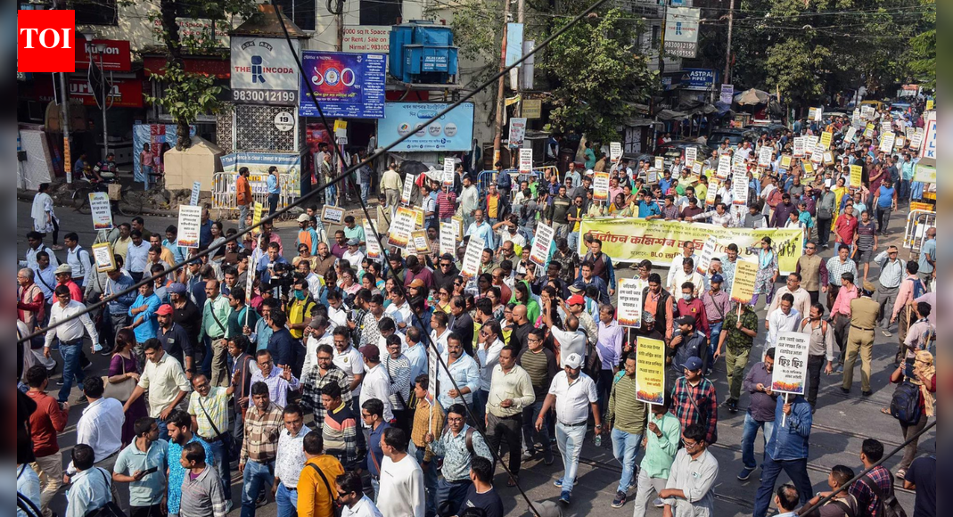 Booth Level Officers in Kolkata protested against work-related stress during the special intensive revision of electoral rolls. The Chief Election Officer stated that District Magistrates have been asked to assist BLOs and investigate the deaths of four BLOs during the exercise. The protest highlights concerns over immense work pressure and its impact on BLOs’ health.  NEW DELHI: As booth level officers protested over the work-related stress due to the ongoing special intensive revision of electoral rolls in Kolkata, West Bengal chief election officer Manoj Kumar Agarwal on Monday said that poll body has asked the district magistrates to “assist the BLOs.”During a press conference, Agarwal was questioned over the alleged “work-related stress” which the BLOs are facing amid the ongoing voter roll purification drive. The CEO said that the poll body has asked the DMs of four districts to postmortem reports of the BLOs who died during the SIR exercise.”We are receiving complaints that BLOs are under pressure and some are falling ill. We have asked the District Magistrates (DMs) to assist them. There are also reports that some BLOs have died. We have asked the DMs of four districts to send the police and PM (postmortem) reports,” Agarwal said.”We will receive their reports in a day or two; only after that will we be able to take action, and on that basis, we will be able to inform the Election Commission of India that the BLOs died on duty due to SIR,” he added.Agarwal, however, steered clear from commenting on the political aspects of the controversy and said, “Definitely the work of the BLO is very hard. Because they have to go to each and every place. They have to collect the forms, give the forms, and digitise the forms. It is not an easy task. So BLOs are putting their level best in the entire thing.”This comes hours after BLOs stages a demonstration outside the office of the Chief Electoral Officer of West Bengal, protesting against excessive work pressure under the Special Intensive Revision (SIR) process.The agitating BLOs also tried to enter the CEO’s office during their protest but were stopped by police, prompting a minor scuffle.Earlier in the day, members of the BLO Adhikar Raksha Committee marched from College Street in north Kolkata to the CEO office in central Kolkata. They carried locks and fetters to symbolically seal the main entrance of the CEO office. After reaching the office, protesters scaled police barricades in an attempt to enter the CEO’s premises.The BLOs accused the Election Commission of not addressing their complaints about the tremendous and inhuman work pressure during the SIR exercise.The committee also alleged that BLOs were falling sick and two of them died by suicide due to stress.The BLO Adhikar Raksha Committee had earlier announced that para-teachers, college professors and teachers from several organisations would join the march to press for immediate intervention by the Election Commission.House-to-house enumeration under the SIR began on November 4 and will continue till December 4, with draft rolls scheduled for publication on December 9.The committee warned that if deadlines are not extended or corrective steps are not taken, it will launch a continuous protest programme.Earlier in the day, chief minister Mamata Banerjee had written to chief election commissioner Gyanesh Kumar on this issue and asked the poll panel to halt the SIR exercise in West Bengal.The protest came days after two female BLOs died by suicide, reportedly due to stress and workload related to SIR, while another BLO suffered a cerebral attack.The committee warned that if deadlines are not extended or corrective steps are not taken by the Election Commission, it will launch a continuous protest movement across the state.About the AuthorTOI News DeskThe TOI News Desk comprises a dedicated and tireless team of journalists who operate around the clock to deliver the most current and comprehensive news and updates to the readers of The Times of India worldwide. With an unwavering commitment to excellence in journalism, our team is at the forefront of gathering, verifying, and presenting breaking news, in-depth analysis, and insightful reports on a wide range of topics. The TOI News Desk is your trusted source for staying informed and connected to the ever-evolving global landscape, ensuring that our readers are equipped with the latest developments that matter most.”Read MoreEnd of ArticleFollow Us On Social MediaVideos“Indian market offers smooth trade opportunities,” says ASSOCHAM Secretary‘Why? Why? Why?’ Mamata Slams EC, Flags ‘Unusual & Alarming’ Moves Ahead of Bengal Polls’Doesn’t Deserve LoP Post’: BJP Slams Rahul Gandhi For Missing CJI Surya Kant’s Oath CeremonyAs Pakistan Halts Afghan Transit, Kabul Boosts India Partnership And Fast-Tracks The Chabahar RouteIndia’s Soft Power Rises As Jaishankar Expands Global Gita Mahotsav, Kurukshetra Festival OutreachPunjab: Anandpur Sahib Hosts 3-Day Tribute on Guru Tegh Bahadur’s 350th Martyrdom Year’They Said Arunachal Is China’: Indian Woman Alleges Harassment After Passport Rejection In ShanghaiRajnath Says India Followed Krishna’s Message In Operation Sindoor After Pakistan Misread Decency‘Enemies of the Nation Are Our Enemies’Owaisi Condemns Delhi Blast’Double Trade By 2030′: Piyush Goyal’s Big Remarks As India, Canada Agree To Resume FTA Talks123PhotostoriesDharmendra’s demise: From Krushna Abhishek, Karan Kundrra to Ankita Lokhande; TV celebs pay an emotional tribute to the legendary actorStruggling with fatty liver? 5 Ayurveda-approved food habits to improve liver healthSpeculation to confirmation: Sonam Kapoor’s second pregnancy becomes a masterclass in maternity fashionDisha Patani to Ananya Panday: The most talked-about fashion moments of the dayPlanning 2026 travels? 10 trending destinations in pictures to inspire youThanksgiving side dishes: 5 easy recipes to try this yearA legend lives on: Nostalgic images of Dharmendra, the ‘He-Man’ of Bollywood10 Indian breakfasts that are high in protein and under 300 calories5 Indian baby name pairs that are perfect for siblingsDharmendra: The late legend’s heartwarming family pictures123Hot PicksDelhi AQI TodayNew Labour CodeChennai rainGold rate todaySilver rate todayPublic Holidays NovemberBank Holidays NovemberTop TrendingNew Labour LawsIslam MakhachevCola Social Security PaymentsBrittany MahomesCanada Citizenship ActDelhi ProtestSmriti Mandhana WeddingJack HughesRama Raju MantenaFortnite Chapter 7 Leaked