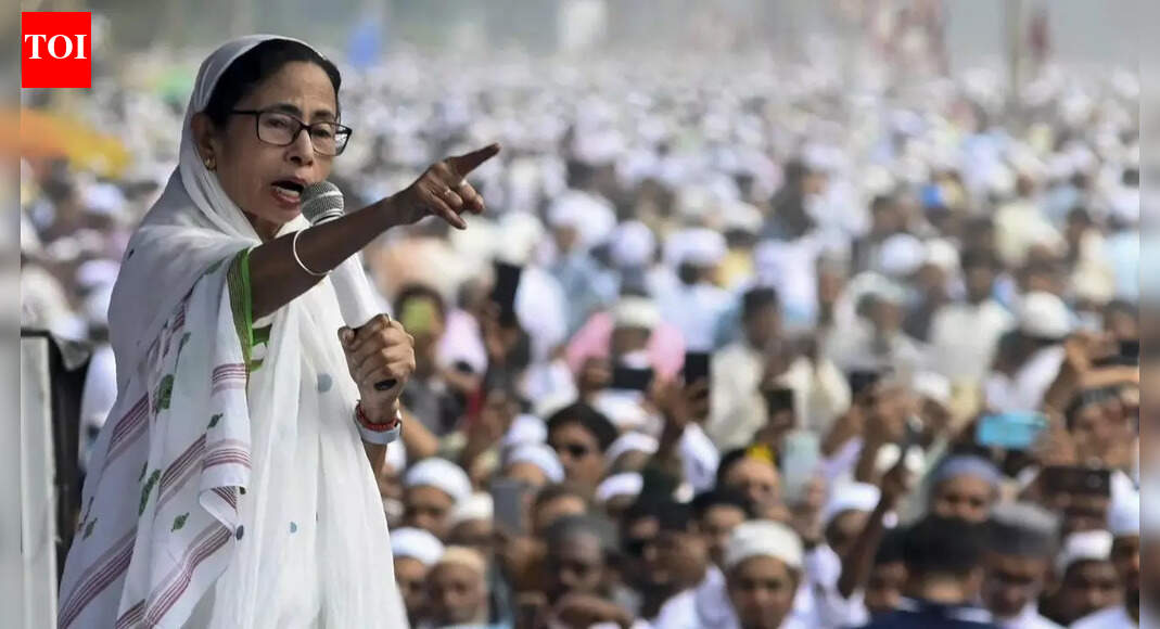 West Bengal CM Mamata Banerjee expressed affection for Bangladesh due to shared language and criticized the BJP-led central government and Election Commission over the Special Intensive Revision (SIR) of electoral rolls. She warned against rushing the process before the 2026 polls and accused the EC of losing impartiality, calling it a ‘BJP Commission’.  NEW DELHI: West Bengal chief minister Mamata Banerjee on Tuesday said she “loves Bangladesh as a country, because their language is same,” before training guns at the BJP-led central government and the Election Commission over the ongoing Special Intensive Revision (SIR) of the electoral roll, warning that the exercise must not be rushed ahead of the 2026 Assembly polls.Addressing an anti-SIR rally in Bongaon, the chief minister told the crowd, “If your name gets deleted, the central government should also be deleted.” Referring to claims that the aim of the SIR is to remove Bangladeshi nationals from the voter list, she asked why the exercise was being conducted in several BJP-ruled states as well and questioned the purpose behind the revision.”I love Bangladesh as a country, because our language is the same. I am from Birbhum, but one day they will call me Bangladeshi. PM Modi got votes in 2024 as per the same list. If your name gets deleted, the central government should also be deleted. Why conducting SIR in such a hurry?” she said.”Till I am here, I will not allow them to throw you out. Nobody can throw you out. If Bangladeshi is a problem, then why are you conducting SIR in Madhya Pradesh and UP?” she asked.She asserted that she has no fear of the ruling party, declaring, “BJP cannot fight and defeat me politically,” and accused the Centre of using the SIR exercise to target voters.Further indicating conditional support for the revision, Banerjee said, “If SIR is conducted over two-three years, we will support the exercise with every possible resource.” The chief minister accused the Election Commission of losing its neutrality, stating that the “EC is no longer an impartial body, it has turned into a ‘BJP Commission’.” She claimed that people would realise the “disaster” caused by the EC and BJP once the draft voter list is published after the SIR. “Does conducting SIR in BJP-ruled states imply the Centre accepts ‘ghuspaithiyas’ exist there?” she asked.These remarks come as the Election Commission has begun the second phase of the Special Intensive Revision across 12 states and Union Territories. The final electoral roll is scheduled to be published on February 7, 2026. The first phase was carried out in Bihar before its Assembly elections.The current phase covers Andaman and Nicobar Islands, Chhattisgarh, Goa, Gujarat, Kerala, Lakshadweep, Madhya Pradesh, Puducherry, Rajasthan, Tamil Nadu, Uttar Pradesh and West Bengal.About the AuthorTOI News DeskThe TOI News Desk comprises a dedicated and tireless team of journalists who operate around the clock to deliver the most current and comprehensive news and updates to the readers of The Times of India worldwide. With an unwavering commitment to excellence in journalism, our team is at the forefront of gathering, verifying, and presenting breaking news, in-depth analysis, and insightful reports on a wide range of topics. The TOI News Desk is your trusted source for staying informed and connected to the ever-evolving global landscape, ensuring that our readers are equipped with the latest developments that matter most.”Read MoreEnd of ArticleFollow Us On Social MediaVideosDecoding Ayodhya’s Dharma Dhwaj And The Deep Meaning Behind Om, Sun And The Sacred Kovidara TreePM Modi Declares India’s 500-Year Resolve Fulfilled With Dharma Flag Ceremony At Ayodhya Ram TempleDiplomatic Row Explodes After China Rejects Arunachal Woman’s Passport During Shanghai Transit HaltAsh Cloud From Ethiopia Hits India’s Airspace At High Speed, DGCA Issues Urgent Safety AdvisoryNew Tripura BSF IG Intensifies Border Vigilance Amid Bangladesh InstabilitySpectacular Tribute: 350th Martyrdom Day of Guru Tegh Bahadur Marked with Light-&-Sound ShowSecond Day of Guru Tegh Bahadur’s 350th Martyrdom Tribute Marked with Devotion in Punjab“Indian market offers smooth trade opportunities,” says ASSOCHAM Secretary‘Why? Why? Why?’ Mamata Slams EC, Flags ‘Unusual & Alarming’ Moves Ahead of Bengal Polls’Doesn’t Deserve LoP Post’: BJP Slams Rahul Gandhi For Missing CJI Surya Kant’s Oath Ceremony123Photostories7 Indian animals that are known for their gentle and calm natureNo more weak legs: 7 exercises for stronger calvesUdaipur Turns Into Celebrity Capital as JLo, Bollywood A-listers Attend Mantena WeddingHow You Show Your Anger According To Your Birth DateSecond Steel Bridge Erected in Ahmedabad for Mumbai-Ahmedabad Bullet Train ProjectFrom being independent to living life on her own terms: Neena Gupta’s 5 bold statements on motherhoodPunjabi aa gaye oye! Diljit Dosanjh sets the Emmys 2025 red carpet on fireDelhi on Edge as Ethiopia Volcano Ash Approaches; Visibility, Flights and AQI Maybe in DangerKnow the things you must strictly avoid according to your birth dateAnanya Panday turns heads in one of the season’s most striking saree gown looks123Hot PicksDelhi AQI TodayNew Labour CodeCyclone SenyarGold rate todaySilver rate todayPublic Holidays NovemberBank Holidays NovemberTop TrendingEthiopian Volcanic EruptionVaishno Devi College AdmissionsStephen CurryJoe Thornton Net WorthStem OPT ExtensionMLB Trade RumorsTravis TurnerAsha Jadeja MotwaniTyson FuryTrump Gold Card