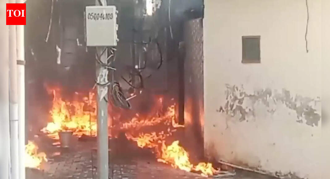 Ambala fire AMBALA: A devastating cylinder blast in Ambala’s Friends Colony on Thursday led to a massive fire, claiming lives of a 1.5-year-old boy and his 31-year-old mother, and leaving her 13-year-old daughter critically injured. The deceased were identified as Ekta and her son Priyans, while her daughter Tanushka is critically injured. Officials confirmed that the blaze intensified due to a large quantity of diesel stored inside the house, turning the incident into a major tragedy. Firefighters have since brought the fire under control, but the house was completely gutted.According to eyewitnesses, the house was being used for making gachak (sweet made of peanuts and jaggery), when a loud explosion shook the area. The impact triggered flames that shot high into the sky, fuelled by the diesel stored in drums. Neighbours reported seeing the house engulfed within minutes, and the fire quickly spread to an adjacent property before the blaze could be contained.Fire brigade teams rescued the three occupants trapped inside and rushed them to the Civil Hospital. Despite receiving medical care, the child and the woman succumbed to their injuries. The injured teenage girl was referred to a higher medical facility at PGI, Chandigarh for advanced treatment.Dr Aditi from the Civil Hospital, Ambala City confirmed the casualties, stating that the victims suffered severe burn injuries. “A 1.5-year-old child and a 32-year-old woman were brought dead. A 13-year-old girl has been referred due to critical condition,” she said.SDM Darshan Kumar, who reached the site, said preliminary findings indicate that the fire was caused by a cylinder blast. “An investigation is underway to determine the exact cause,” he noted.Fire brigade officials informed that four fire tenders were pressed into service. “We received information about a cylinder blast. Four vehicles were dispatched one after another, and the fire was brought under control. Three people trapped inside were rescued,” an officer said.Officials are continuing to probe the circumstances leading up to the blast and the large stock of diesel inside the residential premises.Investigation officer from Ambala City police station, Roshan, said that Priyansh and Ekta could not be saved while Tanushka is undergoing treatment. To a query about gachak unit being run in residential area, Roshan said the matter is being investigated.About the AuthorJaskaran SinghDaily news reporting from the field of agriculture, farmers, crime, health, environment, education, politics, and feature articles from Ambala (with coverage of Kurukshetra & Yamunanagar).Read MoreEnd of ArticleFollow Us On Social MediaVideosImran Khan Health Rumour: PTI Holds Sit In Outside Adiala Jail, KP CM Sohail Afridi Stages ProtestRam Madhav Challenges ‘No-Religion’ Narrative in White Collar Terror DebateAustralia Says India Is Now A Leading Global Power, Credits PM Modi For Transforming World DynamicsOusted PM Sheikh Hasina Faces Fresh Conviction as Court Awards 21-Year TermPM Modi Announces Major Move Allowing Private Players Into Nuclear Sector To Spur Advanced ReactorsExplained: Why Vikram-I Could Transform India’s Satellite Launch Market And Global Space Leadership‘Pak, Bangladesh, US…’: BJP Alleges Congress Using Foreign ‘X’ Accounts to Set India’s NarrativePakistan’s Adiala Jail Issues Statement On Imran Khan’s Health Amid Viral Death RumoursThe Indrajaal Ranger: India Unveils AI-Enabled Anti-Drone Patrol Vehicle In HyderabadBrahMos Diplomacy Peaks As Rajnath Singh Deepens India-Indonesia Defence Ties In Indo-Pacific Shift123PhotostoriesMillie Bobby Brown’s promotional looks for ‘Stranger Things 5’Despite 180 flops and 47 disasters, THIS actor became a cult icon in Russia — His name will surprise youStressed at work? Doctor explains you could be closer to diabetes than you think5 best utensils for daily cooking and how much nutrients they can retainRestricted skies: 5 no-fly zones in India and why planes avoid themDhanush to Kriti Sanon: 5 best fashion looks of the day that are setting major style goals10 surprising things about pregnancy that no one tells you10 unique seven-letter baby names loved by new parentsHow to make South Indian-Style Beetroot Poha for BreakfastSigns that Shani is Upset With You123Hot PicksDelhi AQI TodayNew Labour CodeWorld NewsGold rate todaySilver rate todayPublic Holidays NovemberBank Holidays NovemberTop TrendingDeion SandersAyesha CurryTaylor SwiftMarqury CollinsStefon DiggsSaudi Prince Mohammed Bin SalmanCharlie McAvoyWPL Auction Who Got WhomSteveWillDoIt ControversyCandace Owens