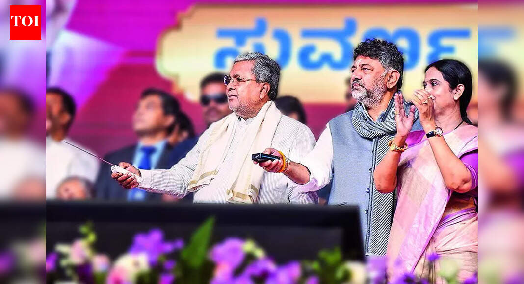 Karnataka’s leadership crisis intensifies as Chief Minister Siddaramaiah invites Deputy CM D.K. Shivakumar for a crucial breakfast meeting following Congress high command’s directive. Both leaders are urged to find a mutual solution, with the high command ready to intervene if discussions fail. Shivakumar’s recent remarks have fueled speculation about his intentions regarding the Chief Minister’s post. Dy CM’s Remark On Sonia Adds To Suspense BENGALURU: With the leadership tussle in Karnataka seeing dramatic twists and turns by the hour, chief minister Siddaramaiah – following a nudge from the Congress high command – on Friday invited his deputy, DK Shivakumar, to a breakfast meeting on Saturday.Siddaramaiah said the high command had spoken to both netas and directed them to meet. “I’ve invited Shivakumar for breakfast at 9am. If he comes, I’ll discuss (the issue) with him,” he said, adding he would obey the high command.A senior party functionary in Delhi said both politicians had been asked to resolve the issue through discussions. “If they don’t, then the high command will intervene,” he said.Another state functionary said the party wanted the two to present “a mutually agreed solution” to the high command, which it would endorse if both were on board.A day after posting a cryptic message on social media, Shivakumar Friday fired a new salvo – that of sacrifice, after promise – by invoking Sonia Gandhi’s decision to forgo the prime ministership while recommending Manhoman Singh’s name in 2004.Even as he lauded Sonia’s leadership, Shivakumar took the opportunity to reach out to voters, urging them to continue backing the Siddaramaiah-led Congress govt. He appealed for public support in the 2028 assembly elections, describing stability as crucial for the party’s long-term plans.While the remarks were framed as praise for Sonia, they triggered a debate within political circles over the message Shivakumar intended to convey. The comments sparked speculation whether he was subtly signalling that Siddaramaiah should make way (sacrifice) for him, or whether he was projecting himself as someone willing to “sacrifice” his chief ministerial claim.Former CM and Union minister M Veerappa Moily criticised the power tussle, calling the situation “practically an anarchy”. In an interaction with a news agency, Moily said the open confrontation had caused “national embarrassment” and blamed Congress high command for “allowing the situation to worsen”. He warned that the party, already weak in many states, could struggle to stay in govt in the state if the “manufactured crisis” was not addressed.Meanwhile, a day after Adichunchanagiri Mutt’s Nirmalananda Swami visited Shivakumar, another prominent Vokkaliga seer, Brahmeshwara Mutt pontiff Gurugunda Nanjavadutha Swami, called on him and publicly backed him for the CM’s post. End of ArticleFollow Us On Social MediaVideosCyclone Ditwah Approaches India: Tamil Nadu, Puducherry, Andhra Pradesh Brace For Impact’Op Sindoor Was Just A Glimpse Of Future Theatre Commands’: Air Marshal Ashutosh DixitPM Modi Unveils World’s Tallest Bronze Statue Of Lord Ram In South GoaIndia Says US Trade Deal Is ‘Only Matter Of Time’ As Tariffs Reshape Bilateral Trade NegotiationsPM Modi Joins Over 1 Lakh Devotees In Mass Bhagwat Gita Recitation At Udupi EventIndia’s Updated Quake Map Warns Entire Himalayan Arc Faces Major Risk, Forcing Urgent Safety Reforms’They Are Ours, We’ll Prove It’: Pakistani Leader’s Absurd Claim On ‘Gujarat, Haryana, Rajasthan’Cyclone Ditwah Intensifies, Monsoon Fury Slams Sri Lanka With At Least 56 Dead And Dozens MissingViral Video: Stage Crashes During UP Wedding As BJP Leaders Gather To Greet Bride & GroomIndia-Russia Summit Dates Out As PM Modi, Putin Review S-400, Su-57 And Global Security Challenges123PhotostoriesRebellious lovers who break every rule to define love in Bollywood moviesAnkita Lokhande reveals she is returning to Laughter Chefs season 3; Krushna Abhishek says ‘We will celebrate Christmas with our Bhauji’4 simple exercises that can help relieve foot pain from diabetic neuropathyGirija Oak Godbole: Surprising facts about the ‘blue saree girl’ you didn’t knowFrom Pythons to Koalas: 5 sleepyhead animals that nap their way through most of the day2 effective drinks to control blood sugar naturally and how to make them at homeRanbir Kapoor, Alia Bhatt to Randeep Hooda: Actors who disappeared with their rolesFrom Saraayah to Sipaara: A look at 2025 Bollywood baby names and their meanings5 countries with zero airports, yet travellers make it in for the experienceSobhita Dhulipala to Shanaya Kapoor: 5 breathtaking celeb looks of the day123Hot PicksDelhi AQI TodayNew Labour CodeWorld NewsGold rate todaySilver rate todayPublic Holidays NovemberBank Holidays NovemberTop TrendingSaquon BarkleyLaMelo BallDonald TrumpDana WhiteAyesha CurryFuzzy ZoellerJammie BookerMarcus FolignoCalgary FlamesVanessa Bryant