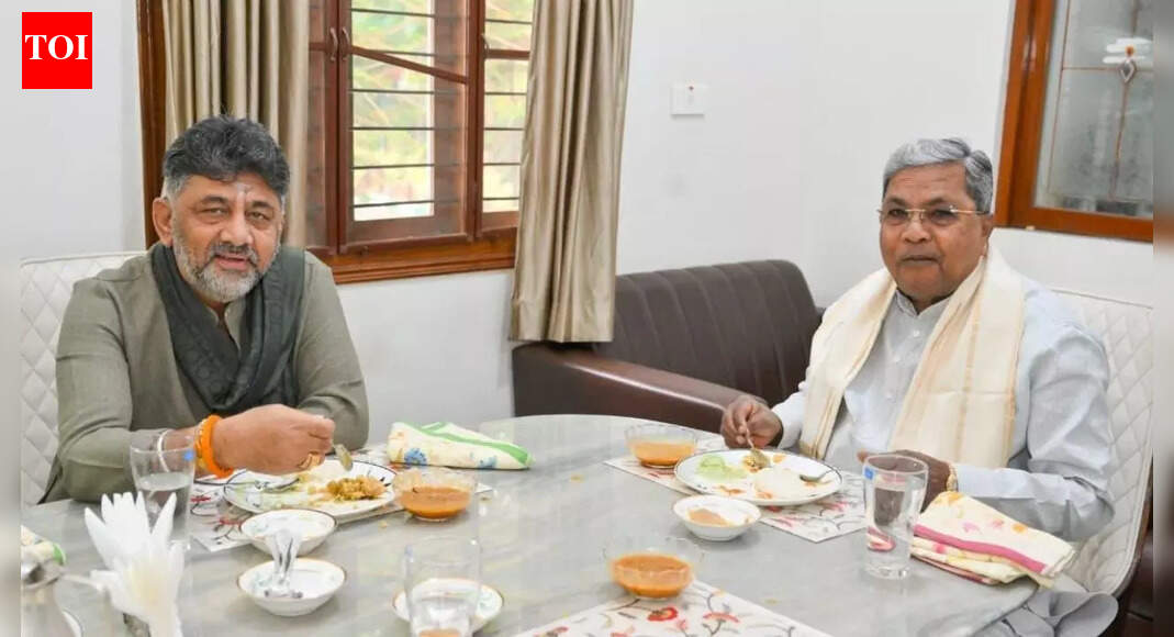 Karnataka’s top leaders, chief minister Siddaramaiah and Deputy CM DK Shivakumar, met for a breakfast discussion following a directive from the Congress high command. Both leaders affirmed their commitment to accepting the party’s decisions regarding leadership. Shivakumar, while acknowledging his supporters’ aspirations, emphasized patience and stated the party will make all choices. Karnataka CM Siddaramaiah meets his deputy DKS amid crisis rumours. NEW DELHI: Karnataka deputy CM DK Shivakumar on Saturday met chief minister Siddaramaiah at the latter’s residence in Bengaluru. With the leadership tussle in Karnataka seeing dramatic twists and turns by the hour, chief minister Siddaramaiah, following a nudge from the Congress high command, had invited his deputy, DK Shivakumar, to a breakfast meeting.’All 140 MLAs Are Mine’: DK Shivakumar Amid Karnataka CM Speculation; Siddaramaiah RespondsSiddaramaiah said the high command had spoken to both netas and directed them to meet.DK Shivakumar with Siddaramiah at his residence.  “The high command has called both of us, so I have invited him (DK Shivakumar) for breakfast, and we will talk there. As I said earlier, I will accept whatever the high command says; there is no change in my stand. Even he (DK Shivakumar) said that whatever the high command says we’ll follow that…” Siddaramaiah said on Friday.The Congress is likely to discuss the crisis with the central leaders after the party’s strategy group meeting ahead of the winter session of Parliament on November 30.Meanwhile, Shivakumar reiterated that the Congress high command will take any decision regarding the leadership.Speaking to reporters in Bengaluru, Shivakumar responded to questions about his supporters wanting to see him as the next CM.”The party workers may be eager, but I am in no hurry. The party will take all the decisions,” DK Shivakumar told reporters. He did not rule out a visit to the national capital, though he clarified that his trip would be to raise several key issues with the Congress leadership ahead of the Winter Session of Parliament.Speaking to reporters in Bengaluru, Shivakumar responded to questions about his supporters wanting to see him as the next CM.BJP calls breakfast meet ‘pure bunkum’ BJP spokesperson CR Kesavan called the breakfast drama, which he said is “nothing but pure bunkum because it is meant to dupe and cheat the people of Karnataka”.”It is a most unbecoming and selfish slugfest for the CM’s musical chair by these two leaders. It exposes the directionless politics of the Congress party and their selfish politics in particular, and also the dysfunctional leadership of the Congress party and Rahul Gandhi,” he said.”Now they are washing dirty linen in public, and the war on social media shows that the Karnataka Congress government is unstable,” the BJP leader said.About the AuthorTOI News DeskThe TOI News Desk comprises a dedicated and tireless team of journalists who operate around the clock to deliver the most current and comprehensive news and updates to the readers of The Times of India worldwide. With an unwavering commitment to excellence in journalism, our team is at the forefront of gathering, verifying, and presenting breaking news, in-depth analysis, and insightful reports on a wide range of topics. The TOI News Desk is your trusted source for staying informed and connected to the ever-evolving global landscape, ensuring that our readers are equipped with the latest developments that matter most.”Read MoreEnd of ArticleFollow Us On Social MediaVideosIndiGo And Air India Warn Of Delays As Airbus Solar Radiation Snag Hits 350 A320 Jets In IndiaPakistan Faces Global Scrutiny as UN Flags Grave Risks to Rule of Law, Judicial Freedom, GovernanceCyclone Ditwah Approaches India: Tamil Nadu, Puducherry, Andhra Pradesh Brace For Impact’Op Sindoor Was Just A Glimpse Of Future Theatre Commands’: Air Marshal Ashutosh DixitPM Modi Unveils World’s Tallest Bronze Statue Of Lord Ram In South GoaIndia Says US Trade Deal Is ‘Only Matter Of Time’ As Tariffs Reshape Bilateral Trade NegotiationsPM Modi Joins Over 1 Lakh Devotees In Mass Bhagwat Gita Recitation At Udupi EventIndia’s Updated Quake Map Warns Entire Himalayan Arc Faces Major Risk, Forcing Urgent Safety Reforms’They Are Ours, We’ll Prove It’: Pakistani Leader’s Absurd Claim On ‘Gujarat, Haryana, Rajasthan’Cyclone Ditwah Intensifies, Monsoon Fury Slams Sri Lanka With At Least 56 Dead And Dozens Missing123Photostories7 everyday Indian foods that help improve your child’s memoryExpert-approved 3 best drinks and their right quantity to reverse fatty liver naturallyWeekly Cosmic Messages From November 29 To December 5, 2025 According To Your Birth DateBrainless but brilliant: 5 animals that survive without a brainJustin Bieber as a doting dad: Times the Grammy winner won our hearts with his love for Jack Blues BieberBengali film stories that shaped generations and still move hearts today10 emotional skills you must teach your childNur Jahan’s Taj Mahal toMaharani Sita Devi’s Star of South Diamond Necklace:5 lesser-known precious royal Indian jewellery piecesRebellious lovers who break every rule to define love in Bollywood moviesAnkita Lokhande reveals she is returning to Laughter Chefs season 3; Krushna Abhishek says ‘We will celebrate Christmas with our Bhauji’123Hot PicksDelhi AQI TodayNew Labour CodeWorld NewsGold rate todaySilver rate todayPublic Holidays NovemberBank Holidays NovemberTop TrendingGiannis AntetokounmpoBo BichetteWWE Smackdown HighlightsDonald TrumpPerez HiltonCyclone DitwahDana WhiteAyesha CurryFuzzy ZoellerJammie Booker