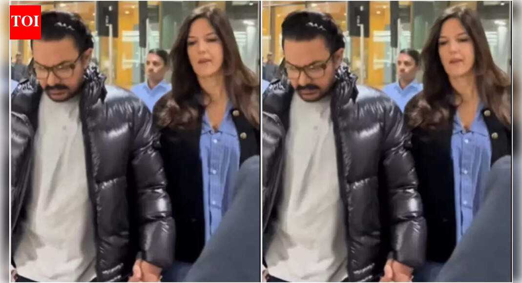 Aamir Khan and Gauri Spratt walk hand-in-hand at airport – watch video