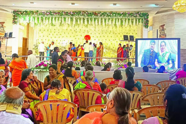 Hubballi/Bhubaneswar: Boarding off, marriage event still on. A software engineer couple who got hitched recently in Bhubaneswar appeared online for their wedding reception in the bride’s Karnataka hometown Hubballi after their IndiGo flight’s last-minute cancellation left them stranded in the Odisha capital.With the reception hall booked in Hubballi, families gathered, and rituals scheduled, the guests took their seats at the venue. The only persons missing were newlyweds Sangam Das and Medha Ksheerasagar.Bengaluru Newlyweds Attend Reception Online After Indigo Cancellations Derail Travel PlansThe couple finally showed up – via video link from Bhubaneswar. They went through the motions on screen in all their wedding finery, completing the event. Medha’s parents sat in the chairs meant for the couple at the venue – a standout moment that stayed with the guests and became another face of the IndiGo fiasco.Bhubaneswar’s Sangam and Medha, who work in Bengaluru, got married on Nov 23 and had a grand reception lined up in Hubballi. The couple had taken tickets from Bhubaneswar to Bengaluru and onward to Hubballi for Dec 2. Tickets for several relatives were also booked for the same day.Then the trouble started. Family members said IndiGo staff kept telling them the flight was “delayed”, beginning 9am on Dec 2 and continuing late into the night. Finally, on the morning of Dec 3 – just hours before the reception – the airline informed the passengers that the flight had been cancelled.With no alternative travel arrangement possible at such short notice, the bride and groom got stuck in Bhubaneswar. “…If IndiGo had informed us earlier, we could have made other arrangements. Because they did not provide timely information, the reception had to be held online,” Medha’s father Anil Kumar told TOI.The couple apologised to the guests with folded hands for not being able to attend the reception in Hubballi in person and thanked them profusely for making the best of the moment despite the disruption.Medha’s father stressed the reception could have proceeded as planned had the airline acted in time. “Because they didn’t provide proper information, we had no option,” Kumar said.End of ArticleFollow Us On Social MediaVideos”Next Year in Russia…” Deputy PM Manturov Urges Indian Companies to Expand Bilateral Trade”Ordinary Indians Pay Price” Rahul Gandhi Calls Indigo Chaos The ‘Cost Of Monopoly Model’India, Russia Renew Call for Inclusive UN Security Council Structure: MEAPutin Says Russia Didn’t Come Only for Energy, Seeks Bold Multifaceted Partnership with IndiaCentre Orders High-Level Probe As IndiGo Flight Operations Set To Normalise In 3 DaysImran Khan Tagged ‘Security Threat’ As Pakistan Army Launches Fiercest Public Attack In Years‘Not Here Only For Energy’: Putin Seeks Broader India-Russia PartnershipPM Modi Urges Putin To Build New Economic Axis As India Becomes Emerging Skilled Capital Of WorldSpiceJet Chairman Ajay Singh Calls IndiGo Crisis ‘Unfortunate’, Offers 100 Extra FlightsPakistan Supports China’s Arunachal Lie As Putin Meets Modi Amid Major India Russia Cooperation123PhotostoriesVijay Deverakonda, Pelli Choopulu and Arjun Reddy; Breakthrough performances that redefined the Telugu lover boyRajesh Khanna-Dimple Kapadia, Saif Ali Khan-Kareena Kapoor Khan; Bollywood marriages spanning age gapsLifestyle expert shares five ‘safe’ ways to drink alcohol if at all one should8 common mistakes people make while making rotis and easy fixes9 fiber-rich dishes made with flattened rice (poha) for breakfastBigg Boss 19: Shehbaz Badesha calls Tanya Mittal fake and irritating; breaks silence on father being trolled for ‘overly friendly’ behaviour with female contestantsAdrian Chiles’ skin cancer diagnosis: How he spotted the symptoms that made all the differenceHow Bhagavad Gita can heal unknown childhood trauma and unlock blockages for success in lifeNutrition fact of the day: Greek yogurt has twice the protein of regular yogurt5 clever animals that deceive predators by playing dead123Hot PicksIndigo Flight DelayPutin India VisitWorld NewsGold rate todaySilver rate todayPublic Holidays NovemberBank Holidays NovemberTop TrendingLos Angeles Lakers vs Boston CelticsNBA trade RumorsOmarion HamptonCandace OwensAryna SabalenkaTrey BensonTravis KelceGeorge PickensStefon DiggsTaylor Swift
