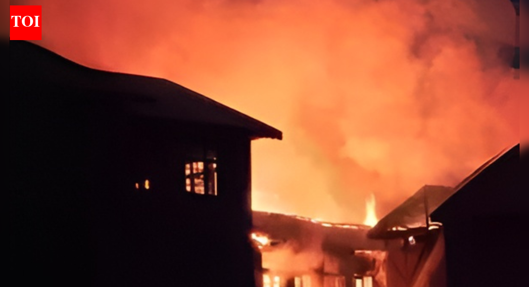 A devastating fire ripped through a North Goa nightclub, claiming at least 25 lives and injuring many more. The blaze, reportedly triggered by an explosion, occurred in an establishment operating without valid permissions. Fire safety norms were not followed, and access for emergency services was severely hampered, leading to a tragic loss of life. Goa nightclub fire (IANS photo) NEW DELHI: A weekend party night in North Goa turned into a tragedy after a massive fire tore through a nightclub in Arpora, killing at least 25 people and injuring many more late Saturday. Eyewitnesses said the blaze followed a “big fire” triggered by a “massive explosion,” in one of Goa’s busiest nightlife belts.Local authorities later confirmed that the club structure itself had no valid permissions. A panchayat official from Arpora said the establishment’s construction “was there without permission,” raising serious questions about regulatory oversight. Goa: 23 Killed In Arpora Nightclub Fire; Cylinder Blast Suspected, CM Sawant Vows Strict Action Several visitors described how close they came to being inside when the inferno erupted. Avanish from Delhi, who had planned to visit the restaurant, said, “…Actually, we got lucky because our cab driver was late or else we would be here…”A security guard at a nearby restaurant recalled the moment the blast shook the area: “…We heard a massive explosion. We later learned that the fire broke out after a cylinder blast…”Nikhnesh, also from Delhi, said he arrived just as smoke began rising. “As soon as we reached our hostel, we saw plumes of smoke rising… Actually, we were planning to come and party here last night… I think there was DJ party yesterday, I don’t know much about it.”Witnesses reported that between 100 and 150 people were on the dance floor when the fire broke out. In the panic, several people rushed downstairs into the kitchen area, where they were trapped along with staff members. Most of the victims, authorities said, were kitchen workers; among the dead were three women and several tourists.Sanjay Kumar Gupta, a security guard at Birch, said the tragedy unfolded within minutes. “The incident occurred between 11 pm and 12 am. Suddenly, there was a fire… I was at the gate… A DJ, dancer was going to come here, and it was about to get really crowded…”Fatima Shaikh, a tourist from Hyderabad, said the nightclub was packed for the weekend. “There was a sudden commotion as the flames started erupting… We rushed out of the club only to see that the entire structure was up in flames,” she said. Many who fled ran into the kitchen, not knowing it was a dead end. “They (tourists) got trapped there along with other staff… Many managed to run out of the club,” she added.The fire spread rapidly, aided by temporary décor made of palm leaves. Access for fire tenders was severely hindered: the club sits along the Arpora backwaters, reachable only through narrow lanes. Tankers had to be parked almost 400 metres away, slowing the response. A senior Fire and Emergency Services officer said the lack of access “made controlling the blaze a challenging task.” Most deaths occurred due to suffocation.Chief minister Pramod Sawant, who visited the site, said the club had not complied with fire safety norms. He announced an inquiry and assured strict action. “The nightclub had not followed the fire safety norms,” he said, adding that both the management and officials who allowed it to run would face consequences.Arpora-Nagoa panchayat sarpanch Roshan Redkar said the club was operated by Saurav Luthra, who was embroiled in a dispute with his partner. “We had inspected the premises and found that they did not have the permission to construct the club,” he said. A demolition notice had been issued earlier, but officials from the directorate of panchayats granted a stay.“The fire incident that happened was unfortunate… Now, we have to be more vigilant,” Redkar added.Calangute MLA Michael Lobo, who also reached the site, said all nightclubs in the area will face a fire safety audit starting Monday. He said notices would be issued seeking valid permissions, and “the licenses of clubs not having the necessary permissions will be cancelled.”About the AuthorTOI News DeskThe TOI News Desk comprises a dedicated and tireless team of journalists who operate around the clock to deliver the most current and comprehensive news and updates to the readers of The Times of India worldwide. With an unwavering commitment to excellence in journalism, our team is at the forefront of gathering, verifying, and presenting breaking news, in-depth analysis, and insightful reports on a wide range of topics. The TOI News Desk is your trusted source for staying informed and connected to the ever-evolving global landscape, ensuring that our readers are equipped with the latest developments that matter most.”Read MoreEnd of ArticleFollow Us On Social MediaVideosGoa: 23 Killed In Arpora Nightclub Fire; Cylinder Blast Suspected, CM Sawant Vows Strict Action’Maligning Hindu Way Of Life’: PM Modi Calls Out Colonial Mindset Over ‘Hindu Rate Of Growth’ LabelUP CM Yogi Slams Parties ‘Insulting Babasaheb’s Legacy’, Announces Security For Ambedkar Statues’Engaging Atmosphere Reigned’: Shashi Tharoor After State Dinner With Russian President Putin’Sab Jagah Pohchenge’: Yogi Adityanath On What’s Next After Ram Temple, ‘Kashi-Mathura’ Slogan’Black Day’: Owaisi Targets Modi Govt, Questions Acquittals In Babri Masjid Demolition CasePutin Dinner Snub Triggers War of Word: Priyanka Chaturvedi Slams ‘Petty’ Politics, BJP Blasts RahulHow Russia May Open Central Asia For India As West Pushes Harder: Kugelman Explains The Power ShiftAviation Meltdown Escalates As IndiGo Cancels 400 Flights And Government Enforces Fare ControlsUS Singer Calls PM Modi World’s Top Leader, Warns Washington To Recalibrate Its India Strategy Fast123PhotostoriesHow to know if your heart is healthy: Simple checks you can do at home5 sleep secrets that transform student performance: What science really saysPowerful mythological names for babies born on SundayYour soul purpose as per your birth month; goosebumps guaranteed!Explore the other wild South: Tamil Nadu’s 6 little-known wildlife sanctuaries to visit4 vitamins that boost brain power, foods rich in them, and a super easy multivitamin drink recipeNutrition fact of the day: Green tea boosts metabolism and helps burn fat more efficiently5 snakes so beautiful that you won’t be able to look awayIn pics: Sourav Joshi and Avantika Bhatt’s simple Pahadi wedding fashion is a hit!Thought of the day for your child: “You are capable of amazing things”123Hot PicksIndigo Flight DelayPutin India VisitWorld NewsGold rate todaySilver rate todayPublic Holidays NovemberBank Holidays NovemberTop TrendingGautam GambhirThe God Slayer Release DateRohit SharmaCandace OwensAryna Sabalenka Net WorthTim PoolAaron RodgersVirat KohliNarela Girl Sexually AssaultedBengaluru News