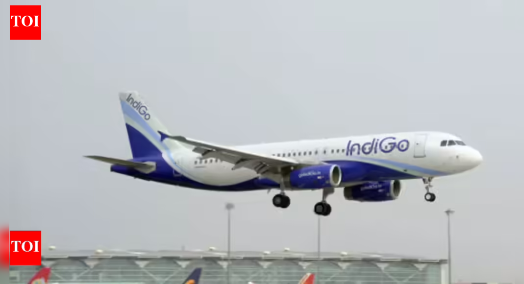 Amidst ongoing flight disruptions, the government is weighing the option of cutting IndiGo’s flight schedule by 5%, with plans to redistribute these time slots to other carriers. IndiGo has acknowledged the issues, attributing them to recent duty requirements and changes in their winter travel timetable. Amidst ongoing flight disruptions, the government is weighing the option of cutting IndiGo’s flight schedule by 5%, with plans to redistribute these time slots to other carriers. IndiGo has acknowledged the issues, attributing them to recent duty requirements and changes in their winter travel timetable.  NEW DELHI: IndiGo may have its schedule cut by 5% and the same – roughly about 110 daily flights – could be given to other airlines that have the resources to add capacity. A livid government is mulling incremental cuts to the schedule starting with 5%, followed by another 5% in coming days if need be, say sources, adding that other actions are also being considered in the wake of the severe disruptions caused by flight cancellations.Meanwhile, a “profusely apologetic” IndiGo has in its reply to the DGCA’s show-cause notice blamed a combination of five factors, including new flight duty time limitation (FDTL) rules and winter schedule-related changes, for its massive flight disruptions.The airline said given the scale of its operations, it is “realistically not possible to pinpoint the exact cause(s)” in the time given. It sought more time for a “comprehensive root-cause analysis”, citing DGCA’s manual that allows a 15-day response time.DGCA may scale down IndiGo ops to make room for othersDGCA is in the process of examining the response and enforcement action as deemed appropriate will be taken in due course,” the aviation ministry said regarding the responses submitted at 6.01pm Monday by CEO Pieter Elbers and COO Isidre Porqueras, who is also the accountable manager.Given the public anger at aviation authorities, it remains to be seen whether IndiGo will be granted more time. The DGCA could now scale down IndiGo’s flights in proportion to its crew strength and make the slots available to other airlines depending on their resource availability. Apart from a hefty financial penalty, the top executives, who are approved by the DGCA, including the airline’s accountable manager (the COO), may face action. The airline, too, may either seek resignations or sack key people seen as responsible for the huge mess.The airline has attributed the disruption to the “compounding effect of multiple factors which coincided in lesser or greater measure” in an “unfortunate and unforeseeable confluence”. It listed these as minor technical glitches; schedule changes linked to the start of the winter season; adverse weather conditions; increased congestion in the aviation system; and implementation of and operation under the updated crew rostering rules (FDTL phase II) that came into force on Nov 1, 2025.”IndiGo notes they had been engaging with the DGCA regarding challenges in implementing FDTL phase II and were seeking variations, exemptions or extensions. The disruptions began in early Dec when the compounding factors resulted in a lower on-time network performance, which affected crew availability,” the aviation ministry said.IndiGo termed the Dec 5 large-scale cancellations, when over 1,000 IndiGo flights – almost half its daily schedule – were affected, as a “drastic measure” of “rebooting” the network “to recover stranded customers, ease airport congestion, and reposition crew/aircraft”.Meanwhile, the four-member DGCA panel probing IndiGo disruption, headed by joint DG Sanjay Brahamane, could summon CEO Pieter Elbers and COO Isidre Porqueras. This panel has been mandated to pinpoint the root cause of this disruption and will examine manpower planning, rostering and IndiGo’s preparedness to implement the new FDTL rules.End of ArticleFollow Us On Social MediaVideos’Nonchalant, Lackadaisical Attitude’: Ex-AirAsia CFO Breaks Down Indigo Fiasco’It Was Treated Like An Extra’: Rajnath Singh Slams Congress For ‘Injustice’ To Vande Mataram’Biggest Mistake’: TMC’s Mahua Moitra Blasts PM Modi, Dares BJP To Win Bengal With Divisive PoliticsIndia Issues Warning To China Over Targeting Indians, Blasts Pakistan’s Remarks On Arunachal PradeshThe Truth Behind Curtailed Vande Mataram : Politics, Unity And A Century Of Cultural TensionAAP MP Raghav Chadha Calls Out ‘Legalised Loot’ Of Toll Plazas In Rajya Sabha’Only 2 Reasons’: Priyanka Gandhi Slams PM Modi, Links Vande Mataram Debate To Bengal Polls’Jinnah Ka Munna…’: Anurag Thakur’s Brutal Attack on Congress, Rips Apart Rahul, Priyanka Gandhi’Will Set An Example’: IndiGo Faces Heat As Aviation Minister Promises Tough Action In Rajya SabhaGoa Club Fire Exposed Deadly Design Errors, Trapping Dozens As Only One Exit Functioned123PhotostoriesRRR, Janatha Garage; Telugu star Jr NTR, whose mass appeal meets surprising versatility onscreenAakrosh, Arth, Salaam Bombay!: Hindi parallel films that redefined meaningful storytelling for new audiencesWhat happens when you stop eating sugar for 30 days5 ways to enjoy egg and spinach for breakfastFood combinations with yogurt that are healthy or can be toxicBoard-certified doctor shares 8 foods that people with arthritis should add to their daily diet5 teen Indian cricketers who are already making waves8 Indian dishes one can make with oats5 deep and emotional RupiKaur quotes on love and heartbreak5 animals with lifespans shorter than a week123Hot PicksIndigo Flight DelayPutin India VisitWorld NewsGold rate todaySilver rate todayPublic Holidays NovemberBank Holidays NovemberTop TrendingOmarion HamptonJaxson DartPatrick MahomesMariasharapova and Alexander Net worthAryna Sabalenka Net WorthJohn TavaresRafael Nadal and Mery Net WorthCandace OwensMirka Federer Net WorthCardi B