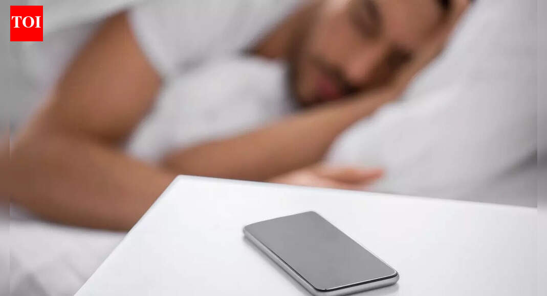 Sleeping next to your phone may cause brain cancer, fertility issues, and other hidden health risks, experts warn about |