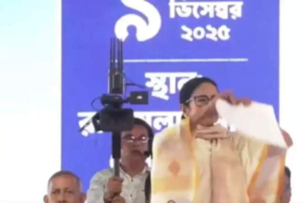 West Bengal Chief Minister Mamata Banerjee publicly tore up new MGNREGA norms, accusing the Centre of imposing ‘valueless’ conditions and withholding funds. She highlighted her state’s Karmashree scheme as an alternative, vowing to increase workdays and asserting Bengal’s fight for dignity and federal rights amidst upcoming elections. Mamata Banerjee NEW DELHI: West Bengal chief minister Mamata Banerjee on Tuesday publicly tore up a note outlining the new MGNREGA norms, escalating her feud with the BJP-led Centre and the saffron party, the poll-bound state’s principal opposition.Banerjee, who leads the state’s ruling Trinamool Congress (TMC), accused the central government of imposing ‘valueless’ conditions for releasing West Bengal’s funds under the Mahatma Gandhi National Rural Employment Guarantee Act (MGNREGA), a central social welfare measure that aims to guarantee the ‘right to work.’“The day before yesterday, we received a letter saying that from December 6, we must submit a quarterly labour budget. They have imposed a restrictive condition. But where is the time to do this? It is already December and elections are due early next year. Then they said training has to be provided. When will you train people and when will you give them jobs?” she said at a rally in Cooch Behar, news agency PTI reported.The chief minister instead promoted her government’s Karmashree scheme, adding that she is confident of winning a fourth consecutive term.“I say this piece of paper (the MGNREGA note) is valueless. We will come back to power. Under Karmashree, we are giving 70 days of work — we will increase it to 100 days. We don’t want your mercy. That is why I am tearing this note. I find it disrespectful,” Banerjee told the gathering.She framed the confrontation with the Centre as a ‘battle for dignity and federal rights,’ asserting, “Bengal has never bowed its head and never will. Bengal knows how to walk with its head held high.”The TMC supremo further alleged that ‘large funds’ under MGNREGA remained pending from the Centre.“The central government has stopped MGNREGA. Even the high court has given an order in our favour. Our party members went to Delhi to protest. Cases were filed against each protesting MP. The train we booked was cancelled. A half-minister gave us a time to meet but did not turn up. Till 2021, we were number one in MGNREGA, Awas Yojana and rural road development. They have stopped all of these out of jealousy and hatred,” she alleged.“We have not received ₹51,627 crore for MGNREGA. They have kept this money hidden. Just before the polls, they will say they have released it, but then there will be no time left for development work. Even if they give it in December, the financial year ends in March, leaving us no time to act,” the chief minister added.The West Bengal assembly elections will be held in April–May next year, with the BJP aiming to unseat Banerjee and the TMC and form its first government in the state. In 2021, the BJP significantly increased its own seat tally but still fell far short of stopping a Trinamool landslide.About the AuthorTOI News DeskThe TOI News Desk comprises a dedicated and tireless team of journalists who operate around the clock to deliver the most current and comprehensive news and updates to the readers of The Times of India worldwide. With an unwavering commitment to excellence in journalism, our team is at the forefront of gathering, verifying, and presenting breaking news, in-depth analysis, and insightful reports on a wide range of topics. The TOI News Desk is your trusted source for staying informed and connected to the ever-evolving global landscape, ensuring that our readers are equipped with the latest developments that matter most.”Read MoreEnd of ArticleFollow Us On Social MediaVideosSingapore Leader Says India Achieved Reforms Once Seen Impossible, Praises Scale and Global ClarityImran Khan’s Sisters Allege Illegal Isolation, Stage Protest Outside Adiala JailRussian President Putin Praises India’s Unity in Diversity, Calls It A Blueprint For Big NationsUS Consumers Facing Food Inflation as Tariffs Hit Indian Rice Imports: Exporters Body’Singapura Derived From Sanskrit’: Singapore’s Ex-Deputy PM Highlights India’s InfluenceInterpol Blue Notice Explained: How CBI Tracks Absconding Luthra Brothers In Goa Nightclub Fire CaseIndia At The Centre: How The New US Security Blueprint Plans To Deepen Strategic Ties With DelhiBJP’s Nishikant Dubey Counters Rahul Gandhi, Accuses Cong Of Weakening India’s Key InstitutionsWhy Trump Accuses India Of Dumping Rice And What A New Tariff Shock Could Mean For Trade Relations’Vote Chori Is The Biggest Anti-National Act’: Rahul Gandhi Slams BJP In Lok Sabha123PhotostoriesSwitch Words According To Your Birth DateThe link between uric acid and sudden night foot pain10 motivating words kids should be taught early12 Jyotirlinga temples you should visit as per your birth monthAura Cleansing Techniques Based On Your Birth Date5 life-changing lessons by the Dalai Lama that can transform your life8 interesting ways to use yellow dal for breakfast6 safe and stunning plants for a pet-friendly balconyMorning habits that reduce your vitamin B12 levels without you realizingAllu Arjun’s fitness routine: How the ‘Pushpa’ star transformed for each role123Hot PicksCandace OwensCharlie KirkWorld NewsGold rate todaySilver rate todayPublic Holidays NovemberBank Holidays NovemberTop TrendingGracie MansionUAE Player TimingAnthony Richardson InjuryTriston JarryVenus Williams and Andrea Net WorthSlient Hill 1 Remake Release DateRafael Nadal and Mery Net WorthTrey Benson Injury updateUPPSC PET ResultGurgaon Man Chicken Momos
