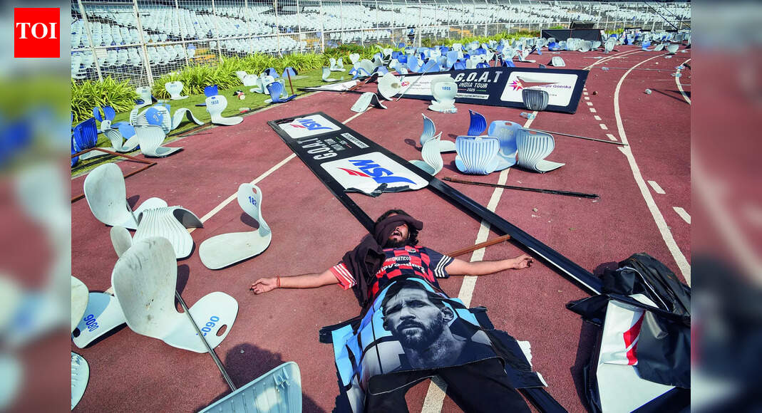 VIPs Surround Stars, Block View From Stands VIPs Surround Stars, Block View From Stands KOLKATA: Frenzy at dawn. Fury by noon. Chaos by afternoon. Lionel Messi’s much-hyped Kolkata appearance collapsed into bedlam at Salt Lake stadium Saturday after tens of thousands of fans who paid steep prices for a glimpse of the football icon saw him for barely minutes – if at all – before he was whisked away, triggering vandalism, pitch invasion and mass outrage.Around 60,000 fans, many in Argentina’s blue-and-white stripes with “Messi” emblazoned on their backs, packed the stands from early morning. Tickets cost between Rs 5,000 and Rs 16,000. Expectations soared. Tempers snapped.Argentina’s World Cup-winning captain stepped onto the pitch at 11.30am to a deafening roar. Within moments, he was engulfed by a crush of VIPs, officials and selfie-seekers. Fifteen minutes later, with the crowd around him refusing to thin out, Messi and Inter Miami teammates Luis Suarez and Rodrigo De Paul were pulled out for security reasons. The stands never got their moment.On the way out, Messi was briefly introduced to former India cricket captain Sourav Ganguly, who had just arrived and taken a seat in a makeshift tent on the pitch. Bollywood star Shah Rukh Khan, scheduled to do a ceremonial lap with Messi, Suarez, De Paul and Ganguly, never entered the stadium. He waited outside, then left as the situation spiralled.When it became clear Messi would not return, the stadium exploded. End of ArticleFollow Us On Social MediaVideosCongress Questions BJP’s Renaming Of MGNREGA, Hits Out At Gandhi HatredMessi Event Chaos In Kolkata Triggers BJP Attack On Mamata Over Law Order And MismanagementMessi Event Chaos In Kolkata: Bengal Police Detain Organiser, Refunds Announced‘Namaste Trump’ Era Is Over As India–US Relations Turn Fragile Over Tariffs, Says Jairam RameshHouse Democrats Push To Scrap Donald Trump’s India Tariffs As Congress Challenges Emergency PowersMessi’s Kolkata Visit Turns Chaotic As Angry Fans Vandalise Banners At Salt Lake Stadium’PM Not Always Wrong’: Ex-Congress Leader Ashwani Kumar, Calls Party Revival A National ObligationAction Over Rhetoric: CDS Anil Chauhan Sends A Calm But Clear Signal To Pakistan Amid Op SindoorWhen Optics Fail: Top Five Global Moments That Turned Pakistan PM Shehbaz Sharif Into A Meme’No Free Lift For India’: PM Modi’s Chief Economic Adviser Says China Won’t Repeat West’s Mistake123PhotostoriesKohinoor and 5 other legendary diamonds every diamond lover should know aboutLow on Energy? Read This According To Your Birth Date5 everyday habits that unknowingly attract rhodents, insects, lizards into your homeThis actress went from TV star to OTT sensation, has a history with Karan Kundrra, and is now linked to a popular cricket commentatorVadodara-Mumbai Expressway Expansion: Rs 100 Crore Construction of 14km Morbe-Kalamboli Road Begins to Ease Traffic and Freight5 reasons why ‘Made-in-India’ sneakers are having a momentWhat your dad secretly taught you about lifeYour hidden spiritual gift revealed… based on your date of birthLonger locals, more relief: Western Railway begins work to extend 15-car locals up to Bandra7 Brilliant leftover rice recipes that are a must try123Hot PicksMukesh Ambani vs Gautam AdaniDonald TrumpAnurag ThakurGold rate todaySilver rate todayPublic Holidays NovemberBank Holidays NovemberTop TrendingSherrone MooreKell MooreH1B Fee HikeWho is Mia SoretyWho is Jeff ShiverNick FuentesDaniel JonesMeghan MarkleShehbaz SharifPaige Shiver Net Worth