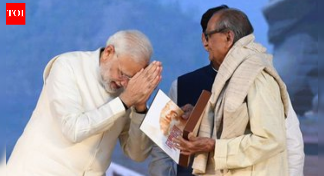 PM Modi with Ram Sutar (Image/X@narendramodi) NEW DELHI: Prime Minister Narendra Modi on Thursday expressed deep grief over the passing of legendary sculptor Ram Vanji Sutar, offering condolences and remembering him as an artist whose creations gave enduring form to India’s history, culture and national pride. Sutar, best known as the designer of the Statue of Unity, the world’s tallest statue, passed away at his Noida residence late on Wednesday night. He was 100 and had been suffering from age-related ailments.The Prime Minister also shared photographs with Sutar, recalling his monumental contribution to Indian art and public memory.In a post on X, PM Modi wrote: “The passing of Shri Ram Sutar Ji has left me deeply saddened. Through his unique sculptures, India has been gifted with several prestigious landmarks, among which the Statue of Unity at Kevadia stands out as a particularly remarkable symbolic creation. His artworks vividly showcase India’s history, culture, and collective consciousness. By giving eternal form to national pride, he has created an invaluable legacy for future generations. His creations will continue to inspire artists and citizens forever. I express my condolences to his family, admirers, and all those affected by his great life’s work. Om Shanti.”Sutar’s son Anil Sutar confirmed his death in a note shared with the press, stating that the renowned sculptor passed away peacefully at home around midnight on December 17.Born on February 19, 1925, in Gondur village of Dhule district in present-day Maharashtra, Ram Vanji Sutar showed an early inclination towards sculpting despite coming from a humble background. A gold medallist from the Sir JJ School of Art and Architecture, Mumbai, Sutar went on to build an extraordinary career spanning several decades, earning global recognition for his mastery of bronze and realistic sculptures.Among his most celebrated works are the Statue of Unity at Kevadia in Gujarat, a 182-metre (522-foot) tribute to Sardar Vallabhbhai Patel, India’s first deputy prime minister and home minister. His other iconic creations include the seated meditative statue of Mahatma Gandhi and the equestrian statue of Chhatrapati Shivaji Maharaj at the Parliament complex. Sutar’s busts of Mahatma Gandhi have been installed in over 450 cities worldwide, further cementing his international stature. He was also associated with major upcoming and ongoing projects, including the Lord Ram statue in Ayodhya and the Chhatrapati Shivaji Maharaj statue in Mumbai.In recognition of his immense contribution, Sutar was awarded the Padma Shri in 1999 and the Padma Bhushan in 2016. Recently, he was conferred the Maharashtra Bhushan Puraskar, the highest civilian award of the state. Earlier this year, Maharashtra CM Devendra Fadnavis, along with deputy CMs Eknath Shinde and Ajit Pawar, presented the award to him in Noida.Tributes poured in from across the political spectrum. Uttar Pradesh chief minister Yogi Adityanath expressed sorrow over the “irreparable loss to the art world,” describing Sutar as the artisan behind the world’s tallest statue. In a post on X, he wrote: “The demise of the great sculptor, the artisan of the world’s tallest statue ‘Statue of Unity’, ‘Padma Bhushan’ Shri Ram V Sutar Ji, is extremely sorrowful and an irreplaceable loss to the art world… Om Shanti!”President Droupadi Murmu also condoled Sutar’s death, remembering him as an artist whose work significantly enriched India’s cultural heritage. In a post on X, she said: “Saddened by the passing of Shri Ram Sutar Ji, Padma Bhushan recipient and an eminent sculptor whose exceptional contributions have enriched India’s artistic and cultural heritage. His monumental works, including the Statue of Unity, stand as great symbols of India’s enduring legacy. His art will continue to inspire generations of artists. I extend my deepest condolences to his family members and admirers.”Union home minister Amit Shah termed Sutar’s passing “extremely heartbreaking,” highlighting his role in creating historical sculptures and restoring artworks at Ajanta and Ellora. BJP president JP Nadda remembered him as one of India’s most respected sculptors, noting that while the artist is no longer with us, his works will continue to keep his legacy alive.Assam chief minister Himanta Biswa Sarma said the nation had lost an “artist par excellence,” recalling Sutar’s work on the statues of Lachit Barphukan in Jorhat and Gopinath Bardoloi in Guwahati. He praised the sculptor’s personal involvement and exceptional craftsmanship in bringing Assam’s heroes to life.The Maharashtra Chief Minister’s Office later announced that Sutar’s mortal remains would be accorded full state honours during the funeral rites in Noida, following a request made to the Union Home Minister and the Uttar Pradesh government.Often compared to masters like Rodin and Michelangelo, Ram Vanji Sutar leaves behind a towering artistic legacy that shaped India’s public spaces and collective imagination. His monumental creations, admired both in India and abroad, will continue to inspire generations to come.About the AuthorTOI News DeskThe TOI News Desk comprises a dedicated and tireless team of journalists who operate around the clock to deliver the most current and comprehensive news and updates to the readers of The Times of India worldwide. With an unwavering commitment to excellence in journalism, our team is at the forefront of gathering, verifying, and presenting breaking news, in-depth analysis, and insightful reports on a wide range of topics. The TOI News Desk is your trusted source for staying informed and connected to the ever-evolving global landscape, ensuring that our readers are equipped with the latest developments that matter most.”Read MoreEnd of ArticleFollow Us On Social MediaVideos’Roz Gandhi Ko Maarte Ho’: BJP MP Nishikant Dubey’s Fiery Speech Targets Cong, Triggers Chaos in LSFrom Work-From-Home To Vehicle Ban- Delhi Rolls Out Fresh Pollution CurbsSeagull With China-Made GPS Device Near Karnataka Naval Base Triggers Spy Buzz; Here’s the Truth’India Got Out Of The Gates Faster Than Most Nations’, Says US Expert As Trade Deal Talks Nears EndRise of Islamists In Bangladesh Sparks Alarm As Sheikh Hasina’s Son Warns India of Imminent Threat“SHANTI Is A Cruel irony”: Tharoor Tears Into Modi Govt Over Nuclear Bill’Vande Mataram’ Chants Echo As Indian Diaspora Welcomes PM Modi In Oman’India-Oman FTA To Open Major Opportunities Across Key Sectors’: Commerce Minister Piyush GoyalBangladesh Leader’s Seven Sisters Remark Triggers Diplomatic Row, India Summons Envoy Issues WarningBusiness Leaders See Major Growth Potential In India-Oman Ties As PM Modi Visits Muscat123PhotostoriesNidhhi Agerwal, Allu Arjun, Deepika Padukone: 5 Times actors were mobbed by fansThis 3 ingredient Ayurvedic drink can regularize periodsTimes Bharti Singh spoke about her son Gola7 smart ways to add sweet potatoes without changing your routineNavi Mumbai’s iconic Vashi Bus Terminal set to transform daily commuting and public transport experienceBlocking sewage, restoring water: How Bengaluru is reviving Byramangala lakeChoking before the first breath: Doctor explains the neonatal crisis in GurgaonIron deficiency: Pale lips and brittle nails are symptoms that your body doesn’t have enough ironSafe, faster, connected: Mumbai’s Mulund East–West foot overbridge nears completion, easing daily commuteNewborn crying decoded: What parents should and shouldn’t worry about123Hot PicksTrump Gold CardUAE WeatherIndia Oman TradeGold rate todaySilver rate todayPublic Holidays DecemberBank Holidays DecemberTop TrendingKyrie IrvingBrian SmithSarfaraz KhanThe UndertakerPatrick Mahomes InjuryUGC Net Exam ScheduleRavi BishnoiNidhhi AgerwalStephen Curry NBA ContractNBA Cup Banner