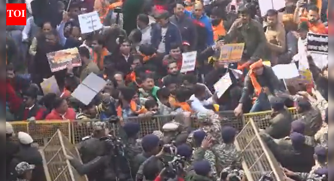 NEW DELHI: Vishwa Hindu Parishad (VHP) on Tuesday held a protest outside the Bangladesh high commission to condemn the mob lynching of Dipu Chandra Das, a Hindu worker in Bangladesh. Visuals showed protesters breaking barricades and clashing with police.Security was beefed up around the commission in the national capital following the protest call by the VHP.Meanwhile, Indian high commissioner to Bangladesh, Pranay Verma was summoned to Bangladesh’s ministry of foreign affairs, reported Prothom Alo.On Monday, Hindu Jagran Manch & Vishwa Hindu Parishad (VHP) jointly staged a protest in front of the Bangladesh visa application centre over atrocities against minorities in Bangladesh. The latest development comes amid heightened tension between the two neighbours, in a fallout of violent protest which erupted in Bangladesh after the fatal shooting of young leader Sharif Osman Hadi linked to last year’s July uprising. Immediately after protests erupted outside the Indian high commission and consulates, along with targeting of Hindu minorities. Both nations have temporarily stopped consular and visa services.What triggered the latest flashpoint?Hadi, a prominent organiser of last year’s July uprising, was shot at close range and later died while receiving treatment abroad. His death sparked widespread protests in Bangladesh.Tensions further escalated when Dipu Chandra Das, a young Hindu factory worker in Mymensingh was lynched by a mob. Hindu organisations and minority rights groups protested in Dhaka, alleging that Das was falsely accused of religious defamation. India has since raised concerns over the safety of minorities and the security of diplomatic missions, rejecting what it called misleading narratives from Dhaka.About the AuthorTOI News DeskThe TOI News Desk comprises a dedicated and tireless team of journalists who operate around the clock to deliver the most current and comprehensive news and updates to the readers of The Times of India worldwide. With an unwavering commitment to excellence in journalism, our team is at the forefront of gathering, verifying, and presenting breaking news, in-depth analysis, and insightful reports on a wide range of topics. The TOI News Desk is your trusted source for staying informed and connected to the ever-evolving global landscape, ensuring that our readers are equipped with the latest developments that matter most.”Read MoreEnd of ArticleFollow Us On Social MediaVideos’Nukes Are Tools For Escalation, Not Peace’: Student Exposes Munir’s Mindset At India vs Pak Debate’India Faces Two War Realities: Counter Terror Strikes And Long Conflicts’, Says CDS Anil ChauhanRahul Gandhi Attacks Modi Govt In Germany, Says ‘West, India Handed Over Production To China’Russia Calls For Reduced Bangladesh-India Tensions, Recalls 1971 WarNew Video Reveals Final Moments of Hindu Man Dipu Before Lynching in BangladeshIndians Trapped By H-1B Renewal Chaos As US VP JD Vance Defends Visa Curbs As Christian PoliticsEx-TMC MLA Humayun Kabir Launches New Party, Targets Mamata Banerjee Ahead of PollsMuhammad Yunus Interim Rule Sparks Alarm, Indian Diplomats Back Hasina On Anti India Narrative ShiftYogi Adityanath Says Vande Mataram Became Victim of Congress Appeasement PoliticsNew Zealand India FTA Sparks Coalition Rift As PM Christopher Luxon Backs Deal, NZ First Rejects It123PhotostoriesCuriosity Corner: How do aeroplanes stay in the sky?Nutrition fact of the day: 7 science-backed nutritional facts about bone brothHollywood celebrity breakups and divorces in 2025: From Nicole Kidman-Keith Urban to Katy Perry-Orlando Bloom5 parenting lessons 2025 taught us8 traditional ragi dishes that have stood the test of time and why they are a winter must haveWhat is the “golden pyramid of fat loss” and why do people mostly start at the wrong levelBaby boy names that means positivityHow to grow healthy papaya tree from seeds in pots in your balconyShin Min-Ah weds Kim Woo-Bin: Shin Min-Ah stuns in the most stunning bridal gown ever! See stylish wedding picsDoes Niagara Falls freeze over in winter? Here’s the truth123Hot PicksUAE WeatherEpstein files releasedGold price predictionGold rate todaySilver rate todayPublic Holidays DecemberBank Holidays DecemberTop TrendingMax Payne Remake Release DateResident Evil Code Veronica Release DateJade Cargill and Bradon Net WorthJosh Allen and Hailee Steinfields HolidayChristen GoffPhilip RiversPaul Heyman and Marla Heyman Net WorthAaron RodgersJade Cargill and Brandon Net WorthCharles Barkley