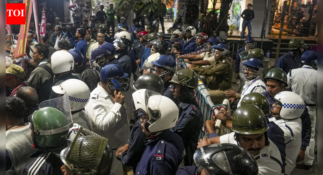 Protests were held across India over killing of Hindu man in Bangladesh Protests condemning violence against Hindus in Bangladesh across across multiple cities in India on Tuesday after a Hindu man was lynched by a mob in Mymensingh. Meanwhile, Bangladesh also witnessed unrest following the killing of political activist Sharif Osman Hadi. Diplomatic tensions rose after demonstrations near Bangladeshi missions in India prompted heightened security, detentions, and the suspension of consular services.The tensions led to India summoning the Bangladesh high commissioner after the latter had called Indian envoy earlier. Experts Warn India As Yunus Loses Control In Bangladesh After Hadi Killing Sparks Unrest Nationwide Dipu Chandra Das’ killing sparks outrageThe protests were triggered by the killing of Dipu Chandra Das in Mymensingh, Bangladesh. Das was allegedly beaten to death by a mob over accusations of blasphemy on December 18, after which his body was set on fire. The incident sparked outrage and renewed concerns over the safety of religious minorities in Bangladesh.India summons Bangladesh high commissioner India summoned Bangladesh High Commissioner Riaz Hamidullah on Tuesday, as reported by ANI. This came after Bangladesh Foreign Ministry had summoned Indian High Commissioner Pranay Verma to convey its “grave concern” over the security of its missionsKolkata: Police lathi-charge protesters near Bangladesh deputy high commissionMembers of Bangiyo Hindu Jagran and several other Hindu organisations staged a protest near the Deputy High Commission of Bangladesh in Kolkata, condemning atrocities against Hindus in Bangladesh and the killing of 27-year-old Hindu man Dipu Chandra Das. Protesters had planned to submit a deputation, but tensions escalated as large crowds gathered near the diplomatic premises.Police said a lathi charge was carried out to prevent a breach of law and order after the situation became volatile.Mumbai and Delhi: VHP protesters detainedIn Mumbai, police detained members of the Vishva Hindu Parishad (VHP) during demonstrations over the same issue.Meanwhile, in the national capital, VHP members and activists from other Hindu organisations were detained near the Bangladesh High Commission after protesters pushed barricades and attempted to enter the premises. Heavy security was deployed as slogans were raised and demonstrators chanted religious slogans while being taken away in police buses.Hyderabad: Minority safety and infiltration concerns raisedIn Hyderabad’s Kothapet area, several Hindu organisations led by the VHP staged protests condemning violence against minorities in Bangladesh. Protest leaders warned of escalating agitation if concrete steps were not taken.VHP National Spokesperson Shashidhar alleged that large numbers of Bangladeshi infiltrators and Rohingyas were living in the city and urged the state government to address security concerns, warning of further action if no response followed.Effigies burnt, anger directed at Bangladesh governmentSentiments against Bangladesh’s interim government intensified during the protests, with demonstrators burning effigies of Chief Adviser Muhammad Yunus and the national flag of Bangladesh. Slogans condemning the Dhaka administration were raised at multiple protest sites.In response to the security situation, Bangladesh suspended consular and visa services in New Delhi and Agartala.Dhaka: Protests over killing of Inqilab Moncho leader Osman HadiMeanwhile, Bangladesh witnessed its own wave of protests after Inqilab Moncho held a rally in Dhaka over the killing of its convenor and spokesperson, Sharif Osman Hadi. The group demanded justice ahead of the upcoming national election and referendum.Hadi was shot at close range on December 12 in Dhaka’s Bijoynagar area and later airlifted to Singapore, where he succumbed to his injuries on December 18.Yunus calls for peaceThe chief of interim government Muhammad Yunus condemned the killing of the Hindu man while calling for peace and assuring justice. “The Office of the Chief Adviser expresses its profound sorrow over the recent killing of factory worker Dipu Chandra Das in Mymensingh and extends its deepest condolences to his family. On behalf of the government, Education Adviser Professor C R Abrar visited the family in Mymensingh on Tuesday to convey the government’s sympathy and assurance of support during this difficult time,” he said in a post on X.”The Interim Government reiterates that this killing was a heinous criminal act with no justification and no place in Bangladeshi society. Allegations, rumours, or differences of belief can never excuse violence, and no individual has the right to take the law into their own hands. The government reaffirms its unwavering commitment to the rule of law. The authority to investigate alleged offences and to ensure justice through due process rests solely with the state,” he added.Further confirming the arrest of 12 individuals with connection to the killing, he said, “Law enforcement authorities have arrested 12 individuals in connection with the crime. Investigations are ongoing, and the Interim Government has directed that the case be pursued fully and without exception. Such acts of violence will be met with the full force of the law. The government remains fully committed to ensuring the safety, dignity, and equal protection of all citizens, regardless of religion, ethnicity, or background. It calls upon all communities, institutions, and leaders to reject violence, resist attempts to create division or unrest, and uphold restraint, humanity, and respect for the law.”Additionally, it stated that it will provide assistance to the man’s family, “The Office of the Chief Adviser confirms that financial and welfare assistance will be provided to the family of Dipu Chandra Das, and that the relevant authorities will remain in close contact with them in the coming period. The Interim Government reiterates its resolve to protect all citizens and to ensure that justice is served.”Bangladesh government promises speedy trialBangladesh’s Law Adviser Asif Nazrul announced that the murder case would be transferred to the Speedy Trial Tribunal under the Speedy Trial Tribunal Act, 2002, requiring completion within 90 days of the police investigation report.Home Adviser Lt Gen (retd) Jahangir Alam Chowdhury said joint forces have arrested 10 people so far, including relatives of the prime accused, Faisal Karim Masud. Authorities said the case is being treated as a top priority.Political Fallout Ahead of Bangladesh ElectionsHadi, a prominent leader of the July uprising that led to the fall of former Prime Minister Sheikh Hasina’s government, was being considered as a potential candidate for the Dhaka-8 constituency in the February 2026 national elections.Following his death, the interim government declared a national day of mourning on December 20, even as Inqilab Moncho warned of a mass movement to oust the government if justice is not delivered.About the AuthorTOI News DeskThe TOI News Desk comprises a dedicated and tireless team of journalists who operate around the clock to deliver the most current and comprehensive news and updates to the readers of The Times of India worldwide. With an unwavering commitment to excellence in journalism, our team is at the forefront of gathering, verifying, and presenting breaking news, in-depth analysis, and insightful reports on a wide range of topics. The TOI News Desk is your trusted source for staying informed and connected to the ever-evolving global landscape, ensuring that our readers are equipped with the latest developments that matter most.”Read MoreEnd of ArticleFollow Us On Social MediaVideosExperts Warn India As Yunus Loses Control In Bangladesh After Hadi Killing Sparks Unrest NationwidePAN-Aadhaar Deadline Nears: How To Link Before December 31 Or Risk Inoperative PAN From Next Year“Neither Janmat Nor Janpath”: Bjp Alleges Growing Rebellion Against Rahul Gandhi Within CongressPak PM Sharif’s Party Leader Threatens India, Warns Missiles Will Respond If Bangladesh Is TargetedIndia’s BrahMos Missile Goes Global As India Closes 0m Defence Pacts With Vietnam And Indonesia’Make Her PM & See…’: Congress MP Endorses Priyanka Gandhi; BJP Takes ‘No Faith In Rahul’ DigHanuman Chalisa Verse Echoes In Delhi As Hindu Lynching In Bangladesh Triggers High Voltage ProtestsAfter Harassment Charge, BJP Leader Nazia Elahi Khan Dares IndiGo To Blacklist HerDonald Trump Praises Asim Munir As ‘Highly Respected’, Reiterates Eight Jets Shot Down in Op SindoorJaishankar Reveals India’s 0 Million Aid Package To Rebuild Sri Lanka After Cyclone Ditwah123PhotostoriesFrom taking her first steps post delivery to updating fans on Kaju’s health and Laughter Chefs shoot, Bharti Singh shares an emotional hospital vlog7 common healthy-looking foods that are secretly causing inflammationInfrastructure Push Ahead as PMC Eyes Rs 200 Cr from Merged ZoneAjith, Suriya, Sasikumar: Tamil stars who charted powerful box office comebacks in 2025Sara Arjun and Ranveer Singh to Deepika Padukone and Shah Rukh Khan: Actors who romanced co-stars with over a 20-year age gap9 pressure cooker mistakes that may turn this ordinary utensil dangerous3 nutrients that may help deal with microplastics in the bodySHE Travels: 7 trips to consider after burnout, breakups or big life changes7 life lessons from Autobiography of a Yogi by to embrace in 2026What happens when you wear sweater and socks while sleeping123Hot PicksUAE WeatherPAN-Aadhaar linkingGold price predictionGold rate todaySilver rate todayPublic Holidays DecemberBank Holidays DecemberTop TrendingMax Payne Remake Release DateResident Evil Code Veronica Release DateJade Cargill and Bradon Net WorthJosh Allen and Hailee Steinfields HolidayChristen GoffPhilip RiversPaul Heyman and Marla Heyman Net WorthAaron RodgersJade Cargill and Brandon Net WorthCharles Barkley