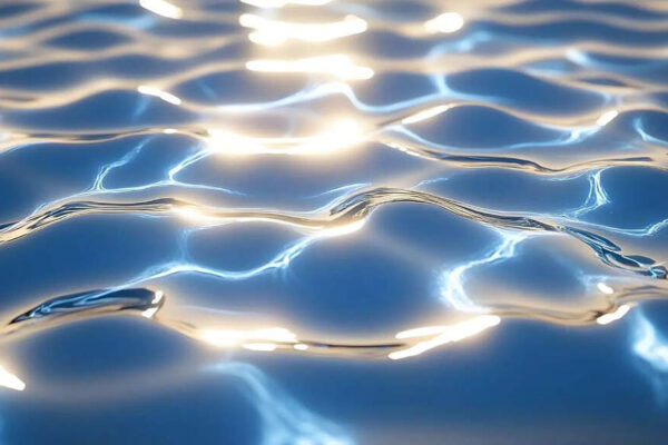What is the colour of water, and why does it look clear in a glass but blue in the sea
