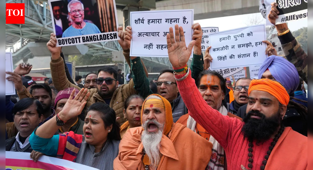 NEW DELHI: The Ministry of External Affairs (MEA) on Friday issued a strong-worded response to the recent incidents of violence in Bangladesh against Hindus and other minorities, warning that these could not be brushed aside as mere “media exaggerations or dismissed as political violence.”Responding to the recent developments in Bangladesh, MEA spokesperson Randhir Jaiswal said, “In the last few days, we have issued more than a couple of statements rejecting the false narrative being projected in Bangladesh.”On the killing of another Hindu man, Amrit Mondal, he said, “We are aware of the recent developments in Bangladesh and are closely monitoring the situation.”Big Test For BNP Chief Tarique Rahman To Rein In Islamists, Calm Bangladesh Amid Violence: Ex-Envoys”The unremitting hostilities against minorities in Bangladesh, including Hindus, Christians and Buddhists, at the hands of extremists are a matter of grave concern. We condemn the recent gruesome killing of a Hindu youth in Mymensingh and expect the perpetrators of the crime to be brought to justice,” the spokesperson said.”Over 2,900 incidents of violence against minorities, including cases of killings, arson and land grabbing, have been documented by independent sources during the tenure of the interim government,” he added.”These incidents cannot be brushed aside as mere media exaggerations or dismissed as political violence,” the MEA spokesperson said.A day after another Mondal was lynched in Bangladesh’s Rajbari district, Yunus-led interim government claimed the incident was not related to communal violence. It said Mondal was “accused” in several serious criminal cases.In the statement, the Bangladeshi government said that it has taken note of the spread of what it termed “misleading information” on social media regarding the killing.On the return of BNP leader Tarique Rahman after 17 years, the MEA spokesperson said, “India supports free and fair elections in Bangladesh, and this development should be seen in that context.”About the AuthorTOI News DeskThe TOI News Desk comprises a dedicated and tireless team of journalists who operate around the clock to deliver the most current and comprehensive news and updates to the readers of The Times of India worldwide. With an unwavering commitment to excellence in journalism, our team is at the forefront of gathering, verifying, and presenting breaking news, in-depth analysis, and insightful reports on a wide range of topics. The TOI News Desk is your trusted source for staying informed and connected to the ever-evolving global landscape, ensuring that our readers are equipped with the latest developments that matter most.”Read MoreEnd of ArticleFollow Us On Social MediaVideosPutin Called Pakistan A Junta With Nukes As Bush Feared Nuclear Leaks To Iran, Reveal TranscriptsTwo Indians Killed In Canada Within A Few Days, Families Raise Question On Safety Of Students AbroadUnnao Rape Convict Kuldeep Sengar’s Bail Triggers Protests In Delhi, Victim’s Mother Demands Hanging’Burn Houses, Murder People’: Brisbane Imam’s Expose of Pakistan’s Attitude Towards MinoritiesBig Test For BNP Chief Tarique Rahman To Rein In Islamists, Calm Bangladesh Amid Violence: Ex-Envoys’Not Genocide But Anger Against Govt’: Cleric On Bangladesh Unrest, Questions Selective OutrageChina Counters Pentagon Report, Extends India Hand On Trust, Borders, Cooperation And StabilityBangladesh Unrest: Another Hindu Man Lynched; Police Claim Extortion Bid‘Hurt Hindu Sentiments’: Bajrang Dal Protests Outside Bareilly Church, Video Viral‘Bit Late but Strong’: Amit Shah Highlights India’s Semiconductor Industry Growth123PhotostoriesFrom Mouni Roy to Tejasswi Prakash: A look back at the leading ladies of ‘Naagin’ ahead of season 7 releaseDelhi’s major wholesale markets one must explore as a tourist5 viral fashion trends and aesthetics that took over Instagram feeds in 2025How to be a good dad: 10 ways to be the father you always wished for5 simple hacks to avoid feeling bloated after holiday mealsRaising confident teens in the digital world of 2026Chennai’s Madhavaram Lake to become city’s first restored lake with jet skis, boating this Pongal6 high-protein winter sabzi that deserve a regular place on the plateWhat makes this European Christmas Market the best in the world?Why is everyone talking about orange juice these days? Key health benefits you are missing out on123Hot PicksUAE WeatherPAN-Aadhaar linkingAmrit MondalGold rate todayIncome Tax RefundIndian Railways fareBank Holidays DecemberTop TrendingCharles BarkleyAnthony DavisStephen CurryJaipur Mosque ViolenceTravis KelceCreed HumphreyShivank AvasthiSophie CunninghamVanessa BryantUS Strike Nigeria