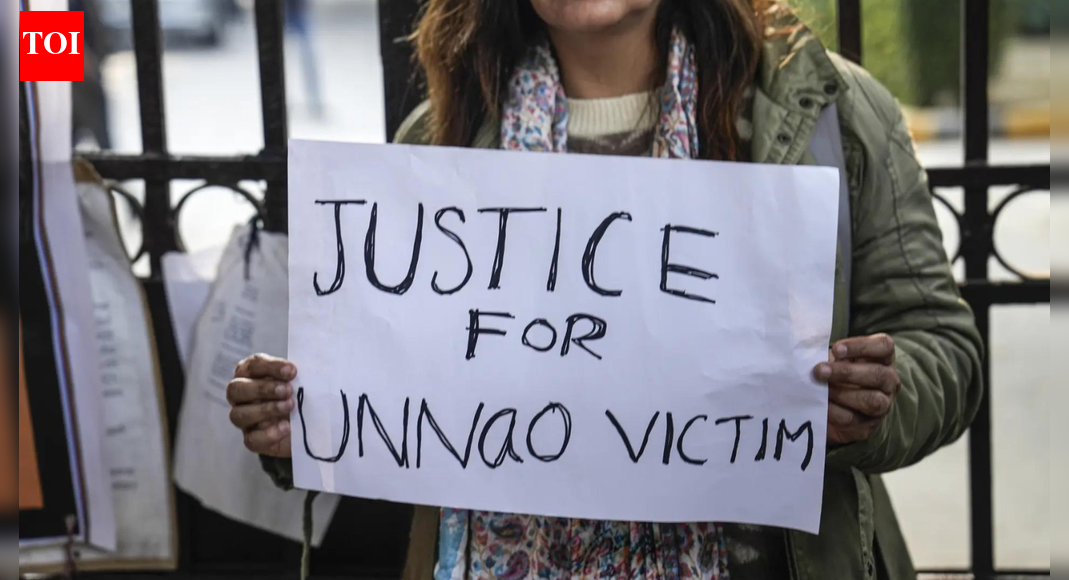 A protester holds a placard during a demonstration against the suspension of the jail term of Kuldeep Sengar NEW DELHI: The survivor of the 2017 Unnao rape case on Sunday said that she fears for the safety of her children after the Delhi high court suspended the life sentence of expelled BJP leader Kuldeep Singh Sengar. Reacting to the CBI’s petition before the apex court, the survivor told news agency ANI, “I have faith in the Supreme Court that it will give me justice. I am raising the voice of every women… Had CBI done this before, I would have got justice. His (Kuldeep Sengar) bail would have been rejected because he raped me. My father was killed. My family members were killed. The security of my family members and witnesses was removed… My husband was fired from his job. My children are unsafe at home.The Supreme Court is scheduled to hear the CBI’s plea on December 29. As per the cause list, a bench headed by Chief Justice Surya Kant, along with Justices J K Maheshwari and Augustine George Masih, will take up the matter. The court will also hear a separate petition filed by advocates Anjale Patel and Pooja Shilpkar challenging the high court’s order.Also read: CBI cites Advani judgment to seek Sengar bail nixingOn December 23, the Delhi high court suspended Sengar’s life sentence in the rape case, noting that he had already served seven years and five months in prison. The suspension will remain in force while his appeal against conviction is pending. The CBI moved the Supreme Court against the order on December 26.Also read: Unnao rape survivor’s explosive charge; meets CBI officialsSengar was convicted in December 2019 and sentenced to life imprisonment along with a fine of Rs 25 lakh. While the high court granted him bail in the rape case, he will continue to remain in jail as he is serving a separate 10-year sentence in a CBI case related to the custodial death of the survivor’s father. His appeal in that case, along with a plea seeking suspension of sentence, is also pending.The high court imposed several conditions while granting bail, including a personal bond of Rs 15 lakh with three sureties, a direction not to enter a 5-km radius of the survivor’s residence in Delhi, and a strict bar on threatening her or her mother.About the AuthorTOI News DeskThe TOI News Desk comprises a dedicated and tireless team of journalists who operate around the clock to deliver the most current and comprehensive news and updates to the readers of The Times of India worldwide. With an unwavering commitment to excellence in journalism, our team is at the forefront of gathering, verifying, and presenting breaking news, in-depth analysis, and insightful reports on a wide range of topics. The TOI News Desk is your trusted source for staying informed and connected to the ever-evolving global landscape, ensuring that our readers are equipped with the latest developments that matter most.”Read MoreEnd of ArticleFollow Us On Social MediaVideos‘Advised Me To Hide In Bunker’: Pak President Zardari On Op Sindoor, Responds To PM Modi’s WarningIndian Army Intensifies Anti-Terror Ops In J&K To Flush Out Pak Terrorists Amid Chillai KalanBJP Hails Shashi Tharoor’s Remarks On India’s Foreign Policy, Congress Hits Back‘Hindu Lives Matter’: Protest Outside Bangladesh High Commission In London Over Minority Killings’MGNREGA Bachao Abhiyan’: Congress Announces Nationwide Protest Against VB-G RAM G ActShimla Hospital Assault: Doctors’ Strike Cripples OPDs, Surgeries Across Himachal PradeshCongress Rift Out In Open? Digvijaya Singh’s Modi-RSS Praise Draws Jibes From BJP Amid CWC MeetMass Exodus Of Skilled Professionals In Pakistan: Report Exposes Asim Munir’s ‘Brain Gain’ ClaimBJP Alleges Anti-India Global Nexus As Congress Leader Rahul Gandhi’s Germany Visit Sparks Fresh RowIndia, Asia Are Rising As Global Epicentres While US, Europe Lose Grip On Power: Russian Ambassador123PhotostoriesChef Sanjeev Kapoor shares hearty non-veg soups for winter comfortManoj Kumar,Asrani, Dharmendra: Legends Bollywood lost in 2025Can amla outperform modern supplements?Ikkis, Border, Raazi: When real war stories inspired Bollywood filmsThe Color You Should Wear on 31st December As Per Your Date of Birth4 fruits that accelerate kidney damage and 3 healthy alternativesUTI in children: Signs, causes and prevention tips every parent must knowRadhika Apte’s fearless roles that break the mould in Raat Akeli Hai: The Bansal Murders, Andhadhun, BadlapurWhat is the “winter vomiting bug” and how it affects the gut4 morning habits that set the tone for success123Hot PicksKuwait NYEPAN-Aadhaar linkingJeffrey EpsteinGold rate todayIncome Tax RefundIndian Railways fareBank Holidays DecemberTop TrendingFrank Lampard and Christine Lampard Net WorthJordan Spieth Net WorthJake Paul and Jutta Net WorthBode Miller Net WorthTravis KelceLola vice and Damian Net WorthPatrick MahomesNavjot Singh SidhuChloe KimNBA Trade Rumor