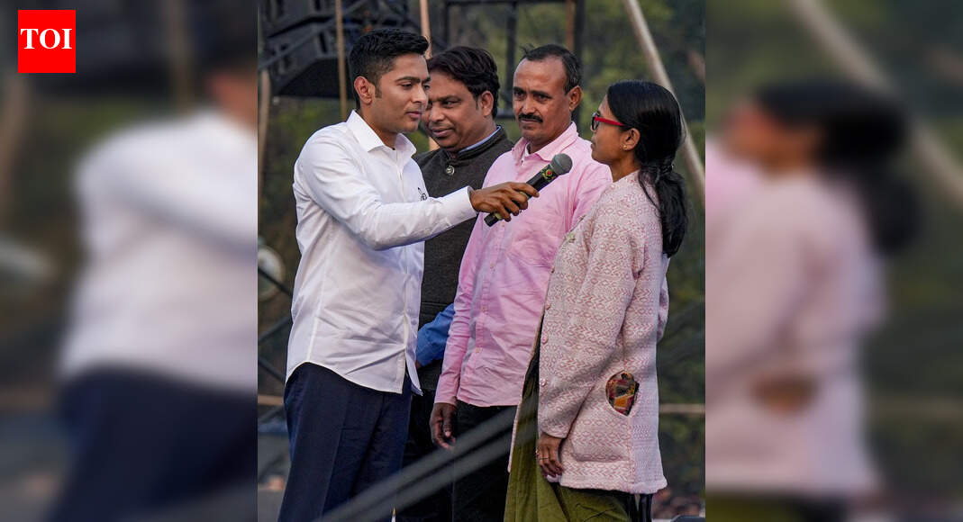 Baruipur: TMC National General Secretary Abhishek Banerjee introduces three people, claiming that they were reported dead in the SIR draft rolls, during a public rally ahead of the West Bengal Assembly election. (PTI Photo/Manvender Vashist Lav) BARUIPUR: “I will make three ghosts walk,” said Trinamool Congress national general secretary Abhishek Banerjee as he ushered in three people on stage – two men from Metiabruz in Kolkata and a woman from Kakdwip in South 24 Parganas – who he said had been marked dead during the SIR of Bengal’s voter rolls. Flagging off Trinamool’s campaign for the 2026 assembly election with a rally in Baruipur on Friday, Abhishek made it clear that SIR would be the front-and-centre of the party’s poll pitch. Abhishek said, “The day before yesterday, we visited the EC’s office in Delhi. I asked (chief election commissioner) Gyanesh Kumar to publish the list of Bangladeshis whose names have been deleted. He couldn’t do it. Instead, he raised his finger at me. I told him, you are nominated, we are elected. Who are you showing aggression to?” “They thought Trinamool would go on the backfoot if they showed slight aggression. But, we have shown what it is to be a Bengali. One day Abhishek Banerjee went (to meet the CEC), Mamata Banerjee will go, too. Who will save you then?” Abhishek added. Introducing the three people – Monirul Islam Molla, Harikrishna Giri and Maya Das – who were marked ‘dead’, Abhishek said there were many more such instances. “In this (South 24 Parganas) district, 24 people who are alive have been shown dead by EC,” he said. The TMC leader in Lok Sabha then went on to slam BJP, saying: “In the name of logical discrepancies, 1.3 crore people were sent notices to attend SIR hearings. BJP can send (legal) notices to me and Trinamool workers. But why are notices being sent to common people? In 2016, they (BJP) made people stand in line for demonetisation. Ten years later, they are making them stand in line for SIR.”End of ArticleFollow Us On Social MediaVideosShankh Air Founder Speaks Out As Airline Eyes March Launch, Targets Intl Flights By 2029’Their Islamist Ideas…’: Ex-Bangladesh Minister Hits Out Over Attacks on Hindus And Christians’Very Petty & Shameful’: Shashi Tharoor On Row Over KKR Selecting Bangladeshi Player In IPLINLD President Calls For Sri Lanka, Bangladesh, Nepal Type Uprising In India Politics, Triggers RowBJP Claims Rahul Gandhi Ties To ‘Anti-India’ Panel Over US Lawmakers’ Umar Khalid LetterNot All Are Illiterate: Rajnath Singh Cites Red Fort Blast, Flags Educated, White Collar Terrorists’Arunachal Pradesh Is And Will Always Be…’ Jaishankar Warns China, Blasts Harassment Of IndiansBullet Train Gets August 15, 2027 India Launch Date, Minister Shares Details On Tunnel BreakthroughCleanest City Hit By Water Contamination As Lab Links Indore Diarrhoea Outbreak To Pipeline LeakUS Lawmaker Raja Krishnamoorthi Condemns Violence Against Hindus In Bangladesh Urges Global Action Up123Photostories7 foods to combine with sweet potato for a wholesome breakfastOlder people who live happily, do these 10 things in their 30 and 40s8 winter pickles to add warmth and taste to your mealsLessons from centenarians: What the world’s longest-living people eat‘Shark Tank India Season 5’: FULL LIST of judges, their net worth, and the brands they ownKylie Jenner-Timothée Chalamet to complete 3 years of dating in 2026: 3 relationship lessons to learn from themHow to make Dhaba-style Dal Makhani at homeAttract True Love During the January 2026 Full Moon; According To Birth Number10 oldest trees in the world that are still living and where can they be foundBest mushroom varieties for vitamin D and how to cook them123Hot PicksPremarital Test OmanVande Bharat Sleeper TrainJanuary Bank holidayGold rate todayIncome Tax RefundBahrain Golden Visa 2025Bank Holidays DecemberTop TrendingSan Francisco 49ersBrittany MahomesNoah Lyles and Junelle Bromfield Net WorthWayne Gretzky Daughter Net WorthSidney Crosby LifestyleLeBron James vs Stephen Curry Net WorthTom BradyLeBron James WifeCam ThomasCharlie Kirk