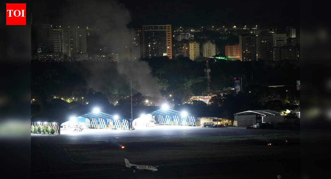 Smoke at La Carlota airport after explosions and low-flying aircraft were heard in Venezuela (AP photo) NEW DELHI: The ministry of external affairs on Saturday “strongly advised” Indians to avoid all non-essential travel to Venezuela, which was hit by multiple strikes by the United States.The MEA also said an email id (cons.caracas@mea.gov.in) and the emergency phone number (+58-412-9584288 / also for WhatsApp calls) to assist Indians amid the uncertain development in the South American nation.Earlier today, the US Persident Donald Trump announced that the US had captured Venezuelan President Nicolas Maduro and his wife in a military operation early on Saturday, following weeks of escalating pressure from the Trump administration.Speaking on Fox News, Trump said the US would play a central role in shaping Venezuela’s future. “We’ll be involved in it very much,” he said, adding: “We can’t take a chance in letting somebody else run and just take over what he left.”Hours after the confirmation, Trump addressed the media, saying: “We’re going to run the country until such time as we can do a safe, proper and judicious transition.”The 47th POTUS described the raid as “one of the most stunning attacks and effective and powerful displays of American military might and competence in American history”.He claimed that no other country could have carried out such an operation, particularly within such a short timeframe. “No nation in the world could achieve what America achieved yesterday,” Trump said, adding that Venezuelan military capabilities had been completely neutralised. About the AuthorTOI News DeskThe TOI News Desk comprises a dedicated and tireless team of journalists who operate around the clock to deliver the most current and comprehensive news and updates to the readers of The Times of India worldwide. With an unwavering commitment to excellence in journalism, our team is at the forefront of gathering, verifying, and presenting breaking news, in-depth analysis, and insightful reports on a wide range of topics. The TOI News Desk is your trusted source for staying informed and connected to the ever-evolving global landscape, ensuring that our readers are equipped with the latest developments that matter most.”Read MoreEnd of ArticleFollow Us On Social MediaVideosInqilab Moncho To March Nationwide Seeking Justice For Sharif Osman Hadi14 Naxals Neutralized In Sukma And Bijapur As Security Forces Launch Anti-Maoist OperationHimachal College Horror: Student Dies After Alleging Sexual Harassment, RaggingIndia Reveals First Vande Bharat Sleeper Offering Faster Overnight Travel On Kolkata-Guwahati LineHindu Businessman Khokon Das, Hacked And Set Ablaze By Mob in Bangladesh, Dies 3 Days After Attack‘Slavery Destroys Heritage’: PM Modi’s Big Message After Unveiling Sacred Buddha Piprahwa RelicsBCCI Asks KKR To Release Bangladesh Player From IPL After Outrage Over Attacks On Hindu MinoritiesGovt Sends Notice To Elon Musk’s X On Grok AI Chatbot Misuse, IT Ministry Seeks Action ReportUttarakhand Minister’s Husband Sparks Outrage With ‘Bihar Girls’ Remark, Congress Hits Out At BJPPakistan Backs China’s Claim That It Mediated In Conflict With India123Photostories5 best Indian forests to see wild Asian elephants in JanuaryKrystle D’Souza’s roles that defined her TV career: ‘Ek Hazaaron Mein Meri Behna Hai’ to ‘Belan Wali Bahu’:TV celebrities’ cutest baby name choices: From Bharti Singh-Harsh Limbachiyaa’s Gola to Nakuul Mehta-Jankee Parekh’s Sufi and Rumi8 short and engaging books you can read in a single day8 traditional and comforting Maharashtrian rice dishes that are worth a tryTravel trend 2026: 5 destinations in Asia perfect for slow travel and ‘quietcations’Krystle D’Souza’s stunning ethnic fashion diaryLord Chandra Names According To Your Birth Date10 must-visit January events in Delhi you can’t missFrom ‘Saiyaara’ heartbreak to ‘FA9LA’ swagger and ‘Name Chale’ grit: Songs that turned 2025 into loudest viral soundtracks123Hot PicksOperation SindoorVande Bharat Sleeper TrainJanuary Bank holidayGold rate todayIncome Tax RefundBahrain Golden Visa 2025Bank Holidays DecemberTop TrendingSan Francisco 49ersBrittany MahomesNoah Lyles and Junelle Bromfield Net WorthWayne Gretzky Daughter Net WorthSidney Crosby LifestyleLeBron James vs Stephen Curry Net WorthTom BradyLeBron James WifeCam ThomasCharlie Kirk