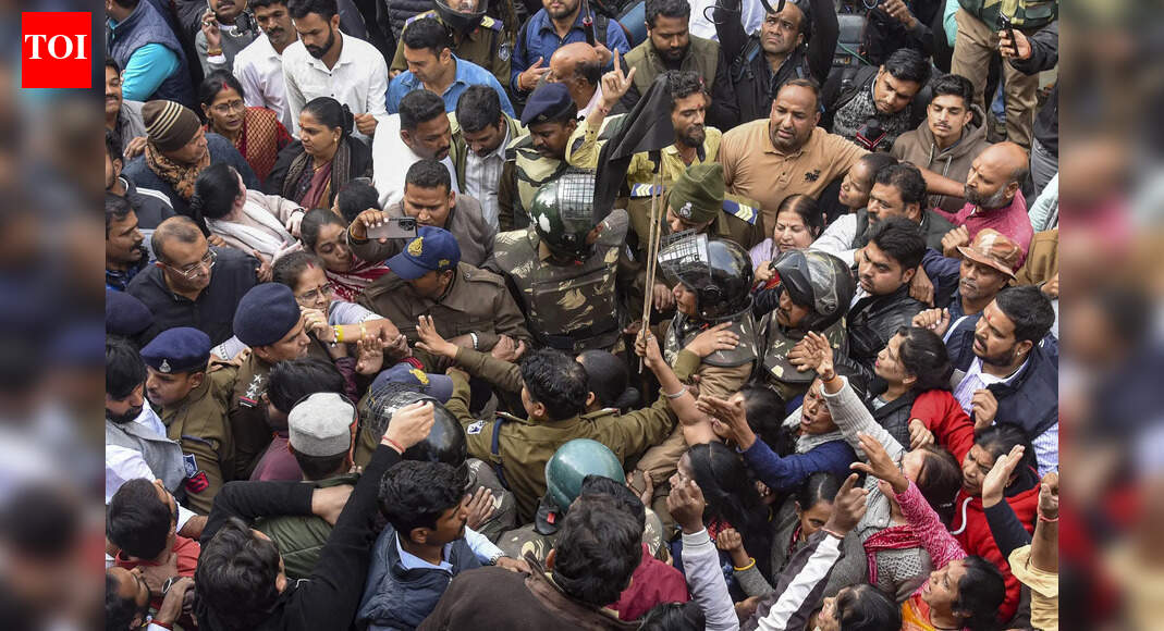 INDORE: Political tension flared in Bhagirathpura area on Saturday as BJP and Congress workers engaged in a fierce confrontation, trading slogans over deaths of 10 people due to contaminated water, reports Sagar Choukse. The confrontation occurred when a Congress fact-finding panel visited the affected locality, prompting police intervention and multiple detentions. Indore officials confirmed another death due to diarrhoea, raising toll to five.When the Congress fact-finding committee arrived to meet affected families, they were met by a large group of BJP workers who staged a counter-protest, shouting “Outsiders go back”. In response, Congress supporters chanted ‘Ghanta Party Murdabad’ (referencing a recent statement by a state minister).The situation escalated as some protesters waved black flags, while others reportedly threw black bangles at the opposing faction. A slipper was also hurled at Congress politician and former state minister Sajjan Singh Verma. As the standoff threatened to turn violent, ACP Amit Singh and other senior police officers intervened. Congress politicians, including Verma, party MLA (Tarana) Mahesh Parmar, party MLA (Sardarpur) Pratap Grewal, state women’s Congress president Reena Bourasi, and city Congress president Chintu Choukse, were forcibly put in police vehicles and removed from the site.”Around 40-50 Congress workers were arrested for disturbing the peace,” additional DCP Rajesh Dandotiya said, adding that the crowd was dispersed. Later, the politicians were released from central jail on filling bonds. Verma launched a scathing attack on the state govt, describing the incident as “murder of democracy” and adding that “police are acting as shields for BJP workers while we are stopped from meeting grieving families”.Meanwhile, chief medical and health officer Dr Madhav Hasani reported that as of Saturday 356 patients were hospitalised, of which 209 had been discharged. End of ArticleFollow Us On Social MediaVideos”No Control Over Minority Violence In Bangladesh…”: Former Indian Envoy Slams Yunus Govt“Infamous For His Tour With Anti-National Propaganda”: BJP Rips Rahul Gandhi Over Vietnam VisitInqilab Moncho To March Nationwide Seeking Justice For Sharif Osman Hadi14 Naxals Neutralized In Sukma And Bijapur As Security Forces Launch Anti-Maoist OperationHimachal College Horror: Student Dies After Alleging Sexual Harassment, RaggingIndia Reveals First Vande Bharat Sleeper Offering Faster Overnight Travel On Kolkata-Guwahati LineHindu Businessman Khokon Das, Hacked And Set Ablaze By Mob in Bangladesh, Dies 3 Days After Attack‘Slavery Destroys Heritage’: PM Modi’s Big Message After Unveiling Sacred Buddha Piprahwa RelicsBCCI Asks KKR To Release Bangladesh Player From IPL After Outrage Over Attacks On Hindu MinoritiesGovt Sends Notice To Elon Musk’s X On Grok AI Chatbot Misuse, IT Ministry Seeks Action Report123PhotostoriesHow to make protein-rich Rajma and Soya Kebab for snackingTop 9 cabbage dishes from around the world5 health facts about the world’s number one longevity food5 most photographed natural monuments in the world to explore in 20265 best Indian forests to see wild Asian elephants in JanuaryKrystle D’Souza’s roles that defined her TV career: ‘Ek Hazaaron Mein Meri Behna Hai’ to ‘Belan Wali Bahu’:TV celebrities’ cutest baby name choices: From Bharti Singh-Harsh Limbachiyaa’s Gola to Nakuul Mehta-Jankee Parekh’s Sufi and Rumi8 short and engaging books you can read in a single day8 traditional and comforting Maharashtrian rice dishes that are worth a tryTravel trend 2026: 5 destinations in Asia perfect for slow travel and ‘quietcations’123Hot PicksOperation SindoorVande Bharat Sleeper TrainJanuary Bank holidayGold rate todayIncome Tax RefundBahrain Golden Visa 2025Bank Holidays DecemberTop TrendingSan Francisco 49ersBrittany MahomesNoah Lyles and Junelle Bromfield Net WorthWayne Gretzky Daughter Net WorthSidney Crosby LifestyleLeBron James vs Stephen Curry Net WorthTom BradyLeBron James WifeCam ThomasCharlie Kirk