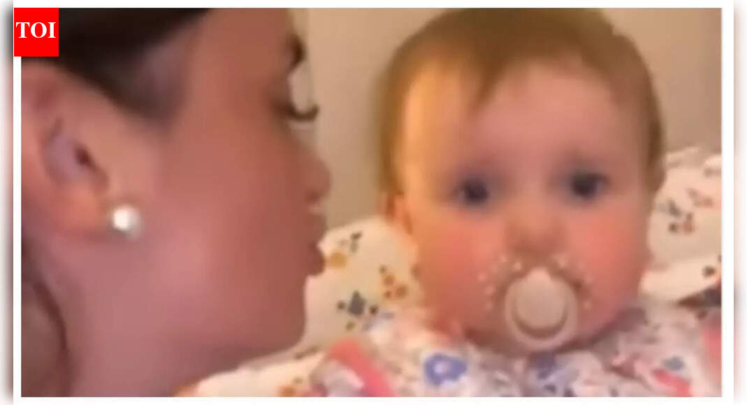 Baby with an attitude: Woman leans in for a kiss, the infant’s ‘eye rolling’ moment goes viral