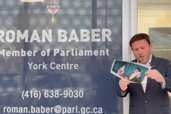 Canada MP joins viral Iran protest trend, lights cigar with burning portrait of Khamenei in front of office