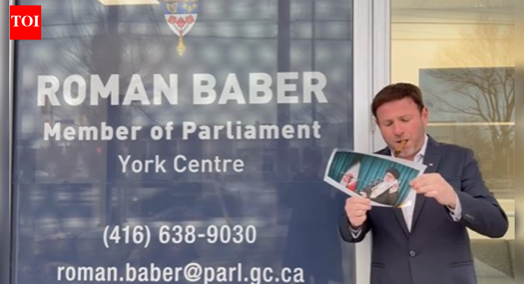 Canada MP joins viral Iran protest trend, lights cigar with burning portrait of Khamenei in front of office