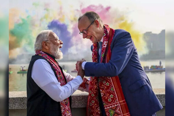 1234 Ahmedabad: Kites, colour and camaraderie defined Monday morning at the Sabarmati Riverfront as Prime Minister Narendra Modi welcomed German Chancellor Friedrich Merz to the International Kite Festival 2026. Sharing an open vehicle, the leaders tried their hand at kite-flying, drawing cheers from spectators. What followed was a sweeping visual of global participation, with kitists from over 50 countries filling the skyline. The event blended diplomacy, tradition and spectacle into a single, soaring narrative.The two leaders moved through the festival arena, pausing to steady their kites against strong gusts and exchanging smiles with cheering spectators. At one point, they stopped to interact with a kitist team from Germany, underscoring the cultural connect the event seeks to foster.The high-profile inauguration followed the leaders’ visit to Sabarmati Ashram, where they paid homage to Mahatma Gandhi. As Modi and Merz arrived at the Riverfront, the sky filled with colour as more than 300 kitists from across India and 50 other countries sent their creations aloft. The display included kites depicting Lord Hanuman, the Indian national flag, and themes such as Operation Sindoor and Vasudhaiva Kutumbakam (the world is one family), alongside large-tailed kites carrying messages like “#GUJARAT IKF2026”, “Har Har Modi, Ghar Ghar Modi”, “Atmanirbhar Bharat” and “I Love Modi”.The welcome was marked by a specially curated cultural programme, highlighted by an Indo-German musical symphony performed by 108 musicians. The ensemble greeted the German delegation with a traditional German tune rendered using classical Indian instruments, including the sitar, flute and tabla, blending musical traditions from both countries.Adding a strong local flavour to the event was a life-size replica of a pol, the traditional neighbourhood of Ahmedabad’s Unesco World Heritage-listed Walled City. The installation recreated narrow lanes, “otla” (outdoor seating space) or extended verandas, and characteristic house facades, with a giant “chabutaro” (bird feeder) forming the centrepiece. Prime Minister Modi guided Chancellor Merz through the makeshift pol, showcasing the craft of kite-making and tracing the history of kite-flying in India through exhibits, dioramas and live demonstrations by artisans.From the Riverfront promenade, the leaders also took in views of the Sabarmati as fireworks and colourful smoke displays were set off on the opposite bank, adding to the festive atmosphere. The broader cultural showcase included music and performances that reflected India’s regional diversity, reinforcing the festival’s role as a meeting point of traditions.For participants, the event remains a unique platform. Kitist Paavan Solanki from Ahmedabad said the International Kite Festival had expanded steadily in both scale and reputation. “The gathering allows kitists from different countries to interact and learn about new ideas and techniques from each other. Ahmedabad has emerged as a global destination for kite enthusiasts because of its enthusiastic crowd and deep-rooted kite culture,” he said.Large numbers of citizens lined the Sabarmati Riverfront to witness the spectacle of kites filling the sky. The festival is open to the public on Jan 12 and Jan 13, with Jan 13 marking the first-ever celebration of night Uttarayan, adding a new dimension to one of Gujarat’s most cherished festivals.About the AuthorParth ShastriParth Shastri is a senior assistant editor covering a wide range of Gujarat-related issues for nearly two decades. He looks after health and higher education as primary beats and also covers extensively on premier educational institutes, public health, science and technology, startups, space and archaeology related to Gujarat.Read MoreEnd of ArticleFollow Us On Social MediaVideosCongress MP says India remains “heavily invested emotionally and politically” in Bangladesh”Our Youth Is Creative And Innovative,” PM Modi At Viksit Bharat Dialogue“Deeply Impressed,” CEOs Share Takeaways After Meeting PM Modi | VideoFrom Defence To AI: PM Modi Urges German CEOs To Make India Their Global Manufacturing Base’Real Friends Always…’: Trump’s New Envoy Sergio Gor Pledges To Reset India-US TiesNot Trade Or Defence: Why Four-Year Old Baby Ariha Shah Became Key Topic In Modi–Germany TalksAAP’s Raghav Chadha Turns Blinkit Delivery Agent for a Day Amid Gig Workers’ Row’Will Come to Mumbai, Try Cutting My Legs: Annamalai Hits Back at Raj ThackerayIndia Tests Indigenous Fire And Forget Anti-Tank Missile With Top Attack Strike On Moving TargetsShaksgam Valley Row Deepens As China Rejects India’s Claim And Defends CPEC Infra Project With Pak123PhotostoriesBreathtaking pictures of Nupur Sanon and Stebin Ben’s stylish Hindu wedding5 animals that survive by pretending to be deadHow to make Halwai Style Aloo Sabji at homeFrom mindful portions to intermittent fasting: When Taarak Mehta Ka Ooltah Chashmah’s Munmun Dutta gave a peek into her disciplined diet and daily routineTimothée Chalamet to Jacob Elordi: The Men of the 2026 Golden Globes who delivered a masterclass in modern tailoringThalapathy Vijay’s ‘Jana Nayagan’ delayed: 8 must-watch OTT hits to streamTamil Nadu Assembly Elections 2026: Alliances, numbers and the battle for 234 seats5 jungle survival tips Bear Grylls swears by, and how they apply beyond the wildChef Sanjeev Kapoor shares 5 crunchy snack recipes to enjoy with chai during winter `Best horror dramas on Apple TV: ‘The Enfield Poltergeist’, ‘Servant’ and more123Hot PicksISRO PSLV-C62 missionTrump tariffsGold rate todayBengaluru newsCigarette price hikePublic holidays January 2026Bank Holidays JanuaryTop TrendingNFL Football Playoff Schedule 2026George Kittle InjuryVanessa Bryant and Natalia Bryant Net WorthBrooks Koepka and Jena Sims Net WorthMorgan GeekieBryce Harper Net WorthTravis Kelce WeddingDonovan MitchellLeBron JamesBudget 2026