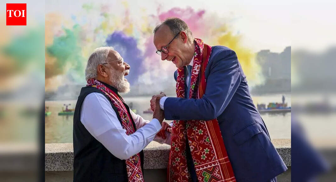 1234 Ahmedabad: Kites, colour and camaraderie defined Monday morning at the Sabarmati Riverfront as Prime Minister Narendra Modi welcomed German Chancellor Friedrich Merz to the International Kite Festival 2026. Sharing an open vehicle, the leaders tried their hand at kite-flying, drawing cheers from spectators. What followed was a sweeping visual of global participation, with kitists from over 50 countries filling the skyline. The event blended diplomacy, tradition and spectacle into a single, soaring narrative.The two leaders moved through the festival arena, pausing to steady their kites against strong gusts and exchanging smiles with cheering spectators. At one point, they stopped to interact with a kitist team from Germany, underscoring the cultural connect the event seeks to foster.The high-profile inauguration followed the leaders’ visit to Sabarmati Ashram, where they paid homage to Mahatma Gandhi. As Modi and Merz arrived at the Riverfront, the sky filled with colour as more than 300 kitists from across India and 50 other countries sent their creations aloft. The display included kites depicting Lord Hanuman, the Indian national flag, and themes such as Operation Sindoor and Vasudhaiva Kutumbakam (the world is one family), alongside large-tailed kites carrying messages like “#GUJARAT IKF2026”, “Har Har Modi, Ghar Ghar Modi”, “Atmanirbhar Bharat” and “I Love Modi”.The welcome was marked by a specially curated cultural programme, highlighted by an Indo-German musical symphony performed by 108 musicians. The ensemble greeted the German delegation with a traditional German tune rendered using classical Indian instruments, including the sitar, flute and tabla, blending musical traditions from both countries.Adding a strong local flavour to the event was a life-size replica of a pol, the traditional neighbourhood of Ahmedabad’s Unesco World Heritage-listed Walled City. The installation recreated narrow lanes, “otla” (outdoor seating space) or extended verandas, and characteristic house facades, with a giant “chabutaro” (bird feeder) forming the centrepiece. Prime Minister Modi guided Chancellor Merz through the makeshift pol, showcasing the craft of kite-making and tracing the history of kite-flying in India through exhibits, dioramas and live demonstrations by artisans.From the Riverfront promenade, the leaders also took in views of the Sabarmati as fireworks and colourful smoke displays were set off on the opposite bank, adding to the festive atmosphere. The broader cultural showcase included music and performances that reflected India’s regional diversity, reinforcing the festival’s role as a meeting point of traditions.For participants, the event remains a unique platform. Kitist Paavan Solanki from Ahmedabad said the International Kite Festival had expanded steadily in both scale and reputation. “The gathering allows kitists from different countries to interact and learn about new ideas and techniques from each other. Ahmedabad has emerged as a global destination for kite enthusiasts because of its enthusiastic crowd and deep-rooted kite culture,” he said.Large numbers of citizens lined the Sabarmati Riverfront to witness the spectacle of kites filling the sky. The festival is open to the public on Jan 12 and Jan 13, with Jan 13 marking the first-ever celebration of night Uttarayan, adding a new dimension to one of Gujarat’s most cherished festivals.About the AuthorParth ShastriParth Shastri is a senior assistant editor covering a wide range of Gujarat-related issues for nearly two decades. He looks after health and higher education as primary beats and also covers extensively on premier educational institutes, public health, science and technology, startups, space and archaeology related to Gujarat.Read MoreEnd of ArticleFollow Us On Social MediaVideosCongress MP says India remains “heavily invested emotionally and politically” in Bangladesh”Our Youth Is Creative And Innovative,” PM Modi At Viksit Bharat Dialogue“Deeply Impressed,” CEOs Share Takeaways After Meeting PM Modi | VideoFrom Defence To AI: PM Modi Urges German CEOs To Make India Their Global Manufacturing Base’Real Friends Always…’: Trump’s New Envoy Sergio Gor Pledges To Reset India-US TiesNot Trade Or Defence: Why Four-Year Old Baby Ariha Shah Became Key Topic In Modi–Germany TalksAAP’s Raghav Chadha Turns Blinkit Delivery Agent for a Day Amid Gig Workers’ Row’Will Come to Mumbai, Try Cutting My Legs: Annamalai Hits Back at Raj ThackerayIndia Tests Indigenous Fire And Forget Anti-Tank Missile With Top Attack Strike On Moving TargetsShaksgam Valley Row Deepens As China Rejects India’s Claim And Defends CPEC Infra Project With Pak123PhotostoriesBreathtaking pictures of Nupur Sanon and Stebin Ben’s stylish Hindu wedding5 animals that survive by pretending to be deadHow to make Halwai Style Aloo Sabji at homeFrom mindful portions to intermittent fasting: When Taarak Mehta Ka Ooltah Chashmah’s Munmun Dutta gave a peek into her disciplined diet and daily routineTimothée Chalamet to Jacob Elordi: The Men of the 2026 Golden Globes who delivered a masterclass in modern tailoringThalapathy Vijay’s ‘Jana Nayagan’ delayed: 8 must-watch OTT hits to streamTamil Nadu Assembly Elections 2026: Alliances, numbers and the battle for 234 seats5 jungle survival tips Bear Grylls swears by, and how they apply beyond the wildChef Sanjeev Kapoor shares 5 crunchy snack recipes to enjoy with chai during winter `Best horror dramas on Apple TV: ‘The Enfield Poltergeist’, ‘Servant’ and more123Hot PicksISRO PSLV-C62 missionTrump tariffsGold rate todayBengaluru newsCigarette price hikePublic holidays January 2026Bank Holidays JanuaryTop TrendingNFL Football Playoff Schedule 2026George Kittle InjuryVanessa Bryant and Natalia Bryant Net WorthBrooks Koepka and Jena Sims Net WorthMorgan GeekieBryce Harper Net WorthTravis Kelce WeddingDonovan MitchellLeBron JamesBudget 2026