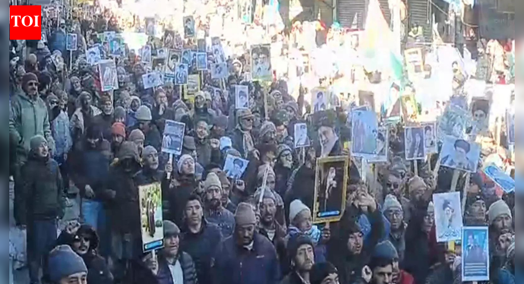 SRINAGAR/LUCKNOW: Ladakh and UP saw a coordinated surge of pro-Iran sentiment as thousands rallied in Kargil district Wednesday and prominent Shia clerics in Lucknow called for sanctions relief, dialogue and Indian support for Tehran.In Kargil, a Shia-majority district in eastern Ladakh bordering PoK, large crowds gathered at multiple locations to back Iran’s supreme leader Ayatollah Ali Khamenei and denounce the US and Israel. The rally, organised by Imam Khomeini Memorial Trust, was led by chairman Sheikh Sadiq Rajai, who accused Washington and Tel Aviv of seeking to dominate the region and destabilise Iran. After Putin & Xi, Saudi, NATO Nation ‘Back’ Khamenei; Trump Gets Chilling Warning Against Iran ‘War’ “We have come out to protest against America and to stand with the brave people of Iran,” Rajai said, urging Islamic nations to unite against what he called US “evil designs”.Demonstrators waved banners praising Ruhollah Khomeini and Khamenei and shouted slogans in Persian and Urdu, while shouting “down with America” and “down with Israel”. Several women addressed the gathering. Police and paramilitary forces were deployed. Officials said protests remained peaceful and also took place in some blocks Thursday.Asgar Ali Karbali, a senior community activist in Ladakh, said Iran has long supported oppressed communities from Lebanon to Palestine. “With this huge protest in Kargil today, we want to show that Iran is not alone,” he said.On Thursday, Shia clerics and community figures in UP echoed support for Tehran and warned against escalation.Maulana Kalbe Jawwad, a leading cleric in Lucknow, said Western sanctions have crippled Iran’s economy and created unrest. “On allegations of uranium enrichment for nuclear weapons, Western powers imposed sanctions on a Shia country. But in reality, they want Iran’s oil… Remove the sanctions, and Iran will flourish,” he said, urging New Delhi to back Tehran rather than remain neutral.Maulana Yasoob Abbas of All India Shia Personal Law Board accused the US and Israel of fuelling unrest and dismissed reports of mass casualties, saying life in Iran was normal. Maulana Khalid Rasheed Farangi Mahali, chairman of Islamic Centre of India and Shahi Imam of Lucknow, said war was no solution and called on the UN to intervene, stressing Iran’s sovereignty and historic ties with India.From Kintoor village in Barabanki district — about 30km southeast of Lucknow and ancestral home of Ayatollah Ruhollah Khomeini’s grandfather — Dr Rehan Kazmi said Western media was distorting events, citing family contacts in Iran who reported large pro-govt rallies.“If Israel or the US attacks, Iran will respond strongly. They have been prepared for this for the past 20 years,” Kazmi said.End of ArticleFollow Us On Social MediaVideosNew Army Video Highlights Operation Sindoor Strikes On Terror Camps And AirbasesBJP MP Sudhanshu Trivedi Warns Against Left Ideologies, Launches Tarun Vijay’S Book Mantra-ViplavFrom Denial To Confession: Lashkar Commander Confirms Op Sindoor Hit, Lays Bare Pak Terror StateIndia-EU FTA Gets A Date As Ursula Von Der Leyen Confirms January Signing With PM ModiH-1B Visa Shake-Up Fuels Anti-Indian Campaigns as Donald Trump’s Policy Reshapes US HiringTrump Visa Crackdown Hits India’s Neighbours, US Pauses Immigration For Pakistan, Bangladesh, Nepal’India Fully Ready For Any Threat And Long Wars Ahead’: COAS Dwivedi Signals Pakistan On Army DayBMC Polls 2026: Inside Mumbai’s Civic Giant Whose Budget Is Bigger Than Many Indian StatesI-PAC Raid Row: SC Halts WB Police FIRs against ED, Seeks Mamata’s ReplyON CAM: 200 Sikhs Rescue 16-Year-Old Girl In London, Say She Was Groomed By Afghan Man123PhotostoriesHow to make South Indian Red Garlic Chutney at homeOne heart? Not enough! Meet 5 animals that go beyondRare baby boy names from Indian mythology that still sound modern in 202614 traditional Gujarati mithais and desserts you must tryExclusive: From revealing the ‘most searched’ question about Shark Tank India on AI tools to advice for young entrepreneurs; Ritesh Agarwal’s candid revelationsA festive style guide to the most beautiful types of parandis5 mountain train journeys in India that prove slow travel is still magicalHow to make Restaurant-Style Garlic Chicken at HomeKriti Sanon, Priyanka Chopra, Shah Rukh Khan: Bollywood stars who turned entrepreneurs and built thriving brands50,000 Bengaluru techies to benefit daily: Skywalk from Metro to ITPB opens tomorrow123Hot PicksIran protestsBudget 2026Gold rate todayBank holiday todayAmrit Bharat ExpressPublic holidays January 2026Bank Holidays JanuaryTop TrendingMemphis Grizzlies vs Orlando Magic Injury ReportNHL Trade RumorsMemphis Grizzlies vs Orlando MagicCameron Jordan PodcastPhil Taylor Net WorthTrea Turner WifeKlay Thompson GirlfriendIndia vs New Zealand ODI MatchBengaluru ScamBTEUP Result