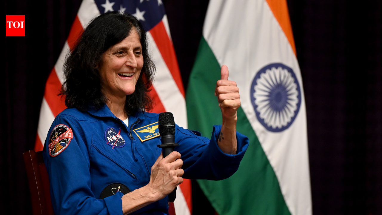NEW DELHI: “When I reached International Space Station for the first time, the first thing I did was to locate India (on Earth), from where my father belonged to, and Slovenia, from where my mother belonged,” said Indian American astronaut Sunita Williams in Delhi on Tuesday — the only female astronaut who has set the world record for most cumulative spacewalking time by a woman with a total of 62 hours and 6 minutes. During her lifetime, Williams went to space three times as a Nasa astronaut, totalling 608 days in space.Williams’s father, Deepak Pandya, is from Jhulasan village in Gujarat’s Mehsana district, where he was born before migrating to the US. Her mother, Ursuline Bonnie Pandya, is of Slovenian-American descent. Nicknamed ‘Suni’ or ‘Soncka’ in Slovenia, Williams was born in the US state of Ohio and has an elder brother, Jay Thomas, and a sister, Dina Ann.“Though I spent nine months in space during my latest trip to the ISS, I missed meeting Group Captain Subhanshu Shukla who reached the station just after I left,” Williams said during an interactive session, ‘Eyes on the Stars, Feet on the Ground’ at American Center here. During her last trip to space before hanging her astronaut suit, Williams went to ISS in 2024 for a scheduled 8-day space trip but had to spend 9 months on ISS as the Boeing Starliner that took her to ISS malfunctioned and had to return empty-handed. Later, SpaceX’s Dragon brought Williams and her crewmate Butch Wilmore back to Earth on March 18, 2025, with the duo ending up spending 286 days in space. India’s Group Capt Shukla went to space as part of the Axiom mission on June 25, 2025.Williams faced several health issues after returning to Earth after remaining in zero gravity for a long time. However, the 60-year-old was seen in high spirits in Delhi on Tuesday, guiding and inspiring Indian students to join the space sector. To cheer her at the Delhi event was the mother of another Indian-American astronaut, Kalpana Chawla, who died in the Space Shuttle Columbia crash in 2003. Williams, wearing a trademark deep blue space overalls and sporting a pair of space-themed canvas shoes, stepped off the dais and reached out to Chawla’s mother, Sanyogita Chawla, 90, who was sitting in the front row, and gave her a warm hug.When asked about the renewed global interest in the Moon, Williams acknowledged the existence of a modern “space race”. “I think there is a space race going on. We want to get back to the moon sustainably and start the conversation about rules of engagement— how we actually work together with other countries. We want to do this in a productive, democratic way, much like Antarctica,” she said.Williams asserted that the horizon of space exploration is rapidly expanding beyond traditional boundaries, stating that the commercialisation of space is creating unprecedented opportunities for innovation. “Commercialisation of space is great. It means there are opportunities for people to work in so many different companies— not only rockets and spacecraft, but parts of space, experiments, satellites, and 3D printing of metals,” she said.“In my childhood, I never dreamt of becoming an astronaut. We used to watch Star Trek on black & white TV. After I did my schooling and graduated, my brother pushed me to join the military and, thereafter, I became a Navy officer,” she said. Williams had logged more than 3,000 flight hours in more than 30 types of aircraft during her career in the US Navy before donning the astronaut suit. While flying aircraft as a Navy commander, I then wished that I should go to the Moon. From then on, I pursued the career of an astronaut,” Williams recalled. “When I reached the ISS, I was craving for Indian food. I was delighted to see that somebody sent me an Indian dish (in the food cargo) though others were making faces. I was glad to also receive 3D printed models of my dogs on ISS.” In Nasa circles, Williams was called the ‘samosa astronaut’, as she liked carrying samosas to space.An athlete since childhood, Williams wanted to participate in a marathon. “So, my sister told me, ‘I will run on your behalf on the ground and you run in space. So that is how I decided to run a marathon in space,” she revealed. Williams ran the Boston Marathon in space in 2007 after qualifying by running the Houston Marathon in 2006, marking the first time a marathon was completed in orbit. She ran on a treadmill aboard the ISS, finishing in 4 hours and 24 minutes while her sister and others ran on Earth.Recalling her most difficult space job, Williams said she went for a spacewalk after the Starliner faced a technical issue and returned to Earth and the Dragon spacecraft was docking at ISS. “While I was replacing a defected reflector, I had ensured that the Dragon capsule was not damaged with my steel helmet. So, I did the job of replacing the reflector by bending my head on one side for over 1.5 hours. After I returned to my space cabin, I faced neck cramps the whole time.” Williams, during her extended 9-month stay on ISS, conducted along with her crew over 150 scientific experiments and technological demonstrations, accumulating more than 900 hours of research across various fields like space gardening, microgravity biology, and water recovery systems.The Nasa astronaut said the perception about life on Earth changes when people go to space. “I am married and I argue with my husband like other couples do. But after reaching space (seeing the vast expanse of universe), I used to wonder why we argue (on minor issues) at all,” she said, adding, “The first thing I ate after returning to Earth was the bread my husband baked for me.”End of ArticleFollow Us On Social MediaVideosSatya Nadella Recounts 2023 Story Of Indian Farmer Leveraging AI Bot For SubsidiesPolice Arrest MZ Wiztown Owner Abhay Kumar Over Noida Techie Yuvraj Mehta’s DeathOwaisi Defends Hijab-Clad PM Dream, Says Constitution Allows It77th Republic Day Parade to Witness Debut of DRDO’s Hypersonic Anti-Ship MissilePM Modi Endorses Nitin Nabin As New BJP Chief; 200% Trump Tariff On French Champagne?One Year Of Trump 2.0: How India-US Ties Went From Strategic Ties To Strategic Stress In 12 MonthsInside Jaish’s Kargil-Style Terror Bunker In J&K Where Maggi, Rice, Gas And Grenades Were StockedEU Puts India At Core Of Historic Trade Reset At Davos, Ursula Leyen Terms It ‘Mother Of All Deals’PM Modi Says Parties Shielding Illegal Immigrants Must Be Exposed, Calls It a National ThreatFrom Karyakarta To Party President: Nitin Nabin Becomes BJP’s Youngest-Ever Chief123PhotostoriesLesser-known facts about Brooklyn Beckham’A Knight of the Seven Kingdoms’: Everything to know about the new Westeros spin-offHow to make Punjabi Lobia Masala for dinner at home‘Jana Nayagan’: Everything to know about trailer, posters, cast and more of Thalapathy Vijay’s starrer amid CBFC delayTop 10 countries with the highest government debtFrom Nimona to Samosa: 9 delicious local dishes made with Green Peas5 reasons you could be on the next layoff list of your companyBaby names as beautiful as a melody‘Sheila Ki Jawani’, ‘Munni Badnaam Hui’, ‘Baby Doll’: Bollywood item songs that broke the internet with their zany lyricsRanbir Kapoor’s ‘Badtameez Dil’ to Nora Fatehi’s ‘Dilbar’: Iconic dance steps from Bollywood songs everyone still tries to copy123Hot PicksSilver price todayBudget 2026Karnataka DGP ScandalGold price predictionNitin NabinPublic holidays January 2026Bank Holidays JanuaryTop TrendingMatthew StaffordKyle Larson and Katelyn Sweet Net WorthKlay ThompsonElina Svitolina and Gael Monfils Net WorthShane Lowry Net WorthTom BradyPaul Scholes and Claire Froggatt Net WorthJohn Harbaughs WifeNHL TradeKelly Piquet