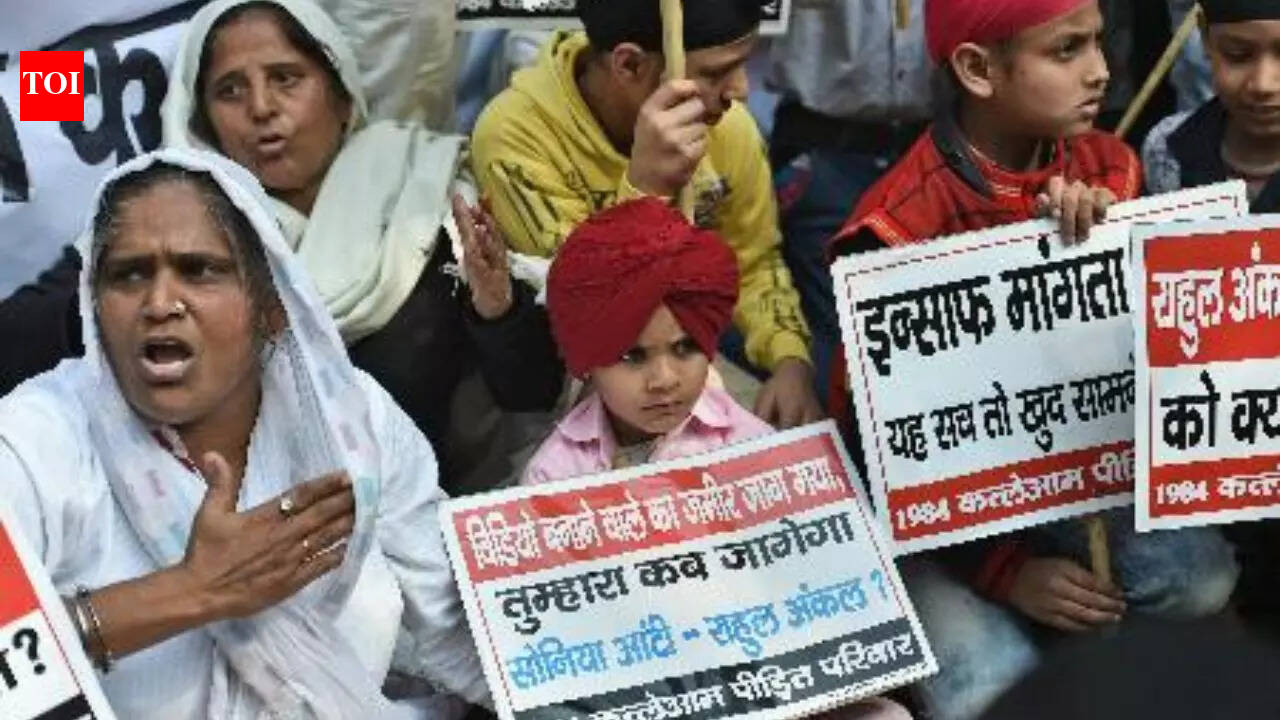 PTI photo NEW DELHI: Outside a Delhi court on Thursday, families affected by the 1984 anti-Sikh riots stood waiting, their faces carrying years of loss and anger. The court had just acquitted former Congress MP Sajjan Kumar in a case linked to alleged incitement of violence in the Janakpuri and Vikaspuri areas, a decision that left them feeling once again unheard.The families said their search for justice had been long and painful. Many of them have spent decades moving from one courtroom to another, hoping for accountability. Kumar, however, continues to remain in prison as he is serving a life sentence in other riot-related murder cases. 1984 Anti-Sikh Riots: Delhi Court Acquits Ex-Congress MP Sajjan Kumar In Vikaspuri, Janakpuri Case Among those present was Nirmal Kaur, who spoke about the day her life changed forever. “My father was burnt alive before my eyes, and I have spent 42 years moving from one court to another, clinging to the belief that justice would one day arrive,” she told PTI.She said everything she valued was taken from her that day. “I myself was destroyed, and every good thing in my life was taken away,” she said, adding that justice still felt distant after all these years.Another woman standing nearby spoke with anger and despair. She said the man she believed was responsible must be punished and hanged. She added that if this did not happen, they would continue to sit outside the court, even if it meant dying there, because they had nothing left to lose.Wazir Singh, a relative of another riot victim, said Kumar had faced around 18 murder cases but had been acquitted in many.“He was responsible for the killing of thousands of Sikhs, and families like mine have spent their entire lives moving in and out of courtrooms,” Singh said.He said the families were prepared to approach the high court and even the Supreme Court, adding that they were no longer afraid to continue the legal fight.For Bagi Kaur, the memories of the riots are still painful and clear. “Ten members of my family were killed. I vividly remember that during the riots, the roads were littered with corpses. One had to jump over dead bodies to cross the road,” she said.She said she watched her family’s future collapse and added that she had not missed a single court hearing in all these years, regardless of the circumstances.“Our pain has now been completely disregarded. Satwant Singh was hanged; then why is the man responsible for the deaths of about a thousand people still alive?” Kaur asked.She said that everyone in court knew whose widow she was, yet no one appeared willing to listen to her.Even after the verdict was delivered, the families refused to leave the court premises. Their protests continued, their voices carrying through the area long after the hearing ended. They said their fight for justice was not over and vowed to keep returning to the courts in search of answers. About the AuthorTOI News DeskThe TOI News Desk comprises a dedicated and tireless team of journalists who operate around the clock to deliver the most current and comprehensive news and updates to the readers of The Times of India worldwide. With an unwavering commitment to excellence in journalism, our team is at the forefront of gathering, verifying, and presenting breaking news, in-depth analysis, and insightful reports on a wide range of topics. The TOI News Desk is your trusted source for staying informed and connected to the ever-evolving global landscape, ensuring that our readers are equipped with the latest developments that matter most.”Read MoreEnd of ArticleFollow Us On Social MediaVideosIAS Officer Sanjeev Khirwar, Who Was Shunted Out Over Dog Walk Row, Returns As Delhi MCD Chief1984 Anti-Sikh Riots: Delhi Court Acquits Ex-Congress MP Sajjan Kumar In Vikaspuri, Janakpuri Case‘Our Neighbour Did Incredibly Well’: India Tech Funding Question Puts Pak Minister On Spot In Davos’India’s Growth Faces Bigger Risk From Pollution Than Trump Tariffs’, Says IMF’s Gita GopinathItaly Says India-EU FTA Is About Trust, Talent And Technology, Not Just Tariffs For Global GrowthAt Davos, Pakistan Seeks More Funds, PM Sharif Calls For Reforms, While His FM Admit Misuse of DebtProtest Held Outside UK Parliament Demanding Labour Govt To Press Bangladesh Over Hindu PersecutionIndia To Grow 6 To 8% In Real Terms In Next 5 Years: Ashwini Vaishnaw At DavosIndia Pushes Urgent Security Council Reform At UN, Says Status Quo Is Fueling Conflict And Misery’China Had A Free Pass, India Won’t’: Sunil Mittal Explains Why India Will Still Win Global Trade123Photostories10 cities across the world facing severe pollution, based on user dataGanesh Jayanti: Deva Ho Deva, Jalwa, iconic Bollywood Ganesha songs that bring festivals to life’Border’, ‘Rang De Basanti’, ‘Delhi 6’: Famous Bollywood movies shot in Rajasthan you may not have known aboutThe 50: From a royal entrance to classy bedrooms- A glimpse of the house where the contestants are going to stayHow songs like ‘Exotic’, ‘Tum Kya Mile’ and ‘Desi Girl’ turned Bollywood into a runway of iconic style momentsWith ‘Toxic’ marking Kiara Advani’s Kannada debut, more Bollywood actors step into South Indian cinema in 2026- Here’s what you need to knowDelhi underground marvel: Pulbangash-Sadar bazaar tunnel in action10 desi Indian dishes among Top 100 Potato Dishes in the worldTaylor Swift’s best movie cameos that stole every scene: ‘Hannah Montana: The Movie’, ‘The Lorax’, and moreBengaluru’s traffic woes go global: City ranks 2nd, Pune 5th most congested123Hot PicksBoard of PeaceBudget 2026Budget 2026 ExpectationsGold price predictionBengaluru AirportPublic holidays January 2026Bank Holidays JanuaryTop TrendingAbhishek SharmaTyler Glasnow Net WorthAaron Judge and Samantha Bracksiecks Age DifferenceJuan Soto Net WorthNico Hoerner Net WorthGiannis AntetokounmpoIBPS RRB PO Mains ResultJosh Allen InjuryFortnite Down V39.30 UpdateDrake Maye