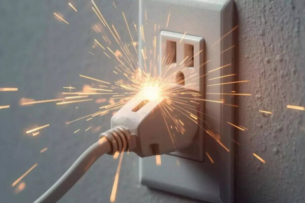 Why your power outlet spark when you plug something in and when it is dangerous