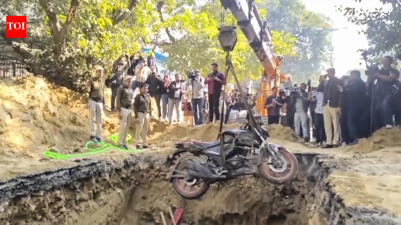 NEW DELHI: Government on Friday suspended three engineers from Delhi Jal Board after a 25-year-old motorcyclist died by falling into a construction pit dug by the water agency in Janakpuri area.According to the police the deceased was identified as Kamal Dhyani, who was returning home from his office on his motorcycle. Here are the top developments’We visited at least 6 police stations’Dhyani’s family said that it did not receive any help from the Delhi Police and accused it of “gross carelessness.” Dhyani’s brother said that he visited six police station but received information about Kamal’s death only after calling him on his phone in the morning, which was received by an official to extend the news of his death.”When I last talked to him, he said he would reach home in 10 minutes. When I called him again at 12:30 am, he didn’t pick up. We got worried. We started looking for him. I first went to his office in Rohini, then to the Janakpuri police station. The police gave us his last location in this area. We kept looking for him but couldn’t find him. This is gross carelessness,” he said.”My brother was not crazy that he would deliberately crash into the pit… At 1:30 am, I checked this pit, but he was not there at that time. We visited at least 6 police stations but did not receive any help… In the morning, when I again called my brother’s phone number, the police picked up the call and informed us that his body had been recovered from the pit… Had the police got into action on time, my brother would have been alive,” he added.’7 people were searching for him from midnight’Kamal’s friend also claimed the police him to wait till 11 am to file a complaint. He added that officials agreed to track the phone but did not share the exact location.After receiving no help from the police, a group of seven people tried to find the victim but failed.”I had talked to him last night when he had reached the District Centre. He was just 15 minutes from home. We waited for an hour, but he didn’t come. An hour later, we came to the District Centre. He had been in accidents twice before, so we thought something like that might have happened. He wasn’t picking up our calls. His bike was nowhere to be seen,” Dhyani’s friend said.”When we went to the police station to file a complaint, we were told that our complaint would not be registered before 11 am. Upon request, the police helped us find the location of my friend and asked us to look for him in a 200-metre radius here. 7 people were searching for him from midnight to 7 am, but we could not find him. At 1 am, when we checked the pit, he was not there. We were on this road all the time, but we don’t understand how he ended up here after we checked,” he added.”When we went back home at 7 am, we received a call from my friend’s phone, and the police informed us that he was in the pit. Why could his phone not be traced by the police at night? We suspect he was killed… What must his parents be going through… We still haven’t informed his mother… He was 25 years old and worked at the HDFC Bank call centre in Rohini Sector 10… Police have been deployed, and barricades have been set up around the pit now. Why couldn’t they do it earlier? My friend could have been saved,” he further said.’We will look into it’Meanwhile, Delhi Police claimed that it tracked Kamal’s phone as soon as his his brother Janakpuri Police Station around 2:45 am. It also claimed that a constable also searched for the deceased with the family members for about 2.5 hours.Deputy comissioner of Police, west Sharad Bhaskar assured that if help was not provided to the family and friends searching for the deceased, the matter would be looked into.”A pit was dug for some work of the Delhi Jal Board. Last night, 25-year-old Kamal Dhyani’s bike fell into this pit, and he unfortunately died. We will investigate all stakeholders of this DJB work. The deceased’s brother came to Janakpuri Police Station around 2:45 am, and he informed that his brother had not reached home yet. The police tracked his mobile phone, which was indicating Janakpuri District Park. Head Constable Ramkesh searched for the deceased with the family members for about 2.5 hours, but they couldn’t find him,” Bhaskar said.”At 8 am today, a woman called the police and informed them that a body was lying in a 15-foot deep pit. This is when everything came to light. As of now, we know that the family visited PS Janakpuri, but if the family says they did not receive help from 6-7 police stations, we will look into it,” he added.Police registers FIRDelhi Police registered an FIR against a contractor and officials of the Delhi Jal Board (DJB) over the death of a 25-year-old motorcyclist who fell into a 15-feet deep pit dug by the civic agency in the Janakpuri area here, an official said.”We have registered an FIR under section 105 (culpable homicide) of the BNS at Janakpuri Police Station against the contractor and concerned officials of Delhi Jal Board,” the senior police officer said.The officer said that investigation is being carried out on priority and strict legal action will taken against the guilty as per lawMinister vows strict actionDelhi urban development minister Ashish Sood expressed grief over the incident and stressed that anyone from the Jal Board found responsible for overlooking the safety protocols will not be spared.”I received news of this unfortunate accident around 8:30-9 am, and I have been here since then… Delhi Jal Board work was in progress here, and I have instructed the Jal Board to investigate the safety protocols. If anyone is found responsible, they will not be spared,” Ashish Sood said.”The Jal Board had conducted an audit of all safety protocols and issued circulars… The police are looking into the cause of the accident… Any official from the Jal Board found responsible for jeopardising the safety measures will not be spared…” he added.Delhi Jal Board sets up committeeThe Delhi Jal Board has set up a committee to probe which will submit a report on the incident by the same evening.In a post on X, Water minister Pravesh Verma said, “DJB has constituted a high-level inquiry committee to ensure a transparent investigation into the incident. The committee has been directed to inspect the accident site immediately and review safety arrangements, barricading, signage and traffic management.”The water minister who inspected the construction site after the incident was reported on Friday ordered the suspension of the DJB officers.”We are suspending three officers-executive engineer, assistant engineer and junior engineer, it was the duty of the three officers to monitor the progress of the work ongoing here,” Singh told reporters.Work at the site has been ongoing for the last three months but the pit was dug on Thursday, he said.’This is not an accident, but murder’Aam Aadmi Party chief Arvid Kejriwal slammed BJP-led Delhi government over the incident and alleged that Kamal’s death was not an accident but a “murder”.In a post on X, the former Delhi chief minister alleged that the BJP learnt nothing from the incident in Noida where a young software engineer died after drowning in a waterlogged plot last month.”This is not an accident, but murder. The BJP has learned nothing even from the Noida incident. Gross negligence and a non-responsible attitude have now become the hallmark of BJP governments, and the common people are paying the price for it,” he added.”May God give strength to that family who lost their child due to the government’s negligence,” he added.’Real culprit is not the road’Congress leader Rahul Gandhi also condemned the death of the motorcyclist claiming that the “real culprit is not the road, but the irresponsible regime.”In a social media post on X, Rahul said, “The epidemic of greed and negligence spreading across Hindustan has claimed another young life today. A son, a dream, the entire world of his parents—all shattered in an instant. This is not an accident; it is murder—and the killer is the power that flees from accountability. The real culprit is not the road, but the irresponsible regime.””Because here there are no resignations, no punishments are meted out, no one’s conscience ever stirs. Indore’s poisoned water, the road in Noida that took Yuvraj’s life collapsing bridges, colliding trains, suffocating pollution. There is no Accountability and until there is accountability, one after another will continue to fall victim to the epidemic of greed,” he added.About the AuthorTOI News DeskThe TOI News Desk comprises a dedicated and tireless team of journalists who operate around the clock to deliver the most current and comprehensive news and updates to the readers of The Times of India worldwide. With an unwavering commitment to excellence in journalism, our team is at the forefront of gathering, verifying, and presenting breaking news, in-depth analysis, and insightful reports on a wide range of topics. The TOI News Desk is your trusted source for staying informed and connected to the ever-evolving global landscape, ensuring that our readers are equipped with the latest developments that matter most.”Read MoreEnd of ArticleFollow Us On Social MediaVideosFrom Exam Stress to Life Skills: PM Modi Engages Students in Pariksha Pe Charcha 2026Deadly Blast At Shia Religious Centre In Islamabad Raises Questions On Pakistan’s Security Failures’New Phase In Bilateral Ties’: Indian High Commissioner Hails PM Modi’s ‘Historic’ Malaysia VisitNorway PM Questions World War II-Era UNSC, Echoes India’s Demand For Reform And Global South VoiceAs Bangladesh Elections Near, Hindu Minority Faces Rising Attacks, Islamist Return And State SilenceBeyond Tariffs: The India–US Deal and the Politics of OilIndia To Push For Tech Defence And Zakir Naik Extradition During PM Modi’s High Stakes Malaysia TripAAP Leader Lucky Oberoi Shot Dead Outside Gurdwara In Jalandhar, Raising Fresh Law Order FearsCricket Nationalism for Cameras, Dollars Dictate Reality? Why Pak Courted Ex-World Bank Chief BangaHAL Clarifies AMCA Status, Says It Will Bid For India’s Fifth-Generation Fighter Jet In 2035 Phase123Photostories10 iconic rajma dishes enjoyed across the globeApple TV shows to look forward to in 2026: ‘Imperfect Women’, ‘Margo’s Got Money Troubles’ and morePrince Narula, Tejasswi Prakash, and more: Can you guess these reality TV stars from their childhood picsValentine’s Week Full List 2026: Rose Day to Kiss Day, here is the complete list of Valentine Week 2026The mystery behind Leonardo da Vinci’s lost masterpieces and what historians sayFall in love, Bollywood style: 5 saree looks perfect for Valentine’s Day‘Vadh 2’ star Neena Gupta’s 5 unfiltered views on motherhood and living life her wayTop 1% habits that make people respect you instantlyLong before ‘Dhurandhar,’ ‘Border 2,’ or ‘Jawan,’ THIS 1969 release shattered records by running to packed houses for 100 days, minting nine times its cost5 key factors that deeply impact the real estate market and what every buyer should know123Hot PicksBudget 2026Gold Silver PricesParliament Budget SessionGCC Unified Visa 2026Income Tax CalculatorPublic holidays February 2026Bank Holidays februaryTop TrendingGCC Unified VisaRamadan 2026Golden State Warriors vs Phoenix Suns InjuryPhiladelphia 76ers vs Los Angeles Lakers injury reportNFL Trade RumorsMyles Garrett GirlfriendSuryakumar YadavGhaziabad Suicide CaseJim BentT20 World Cup