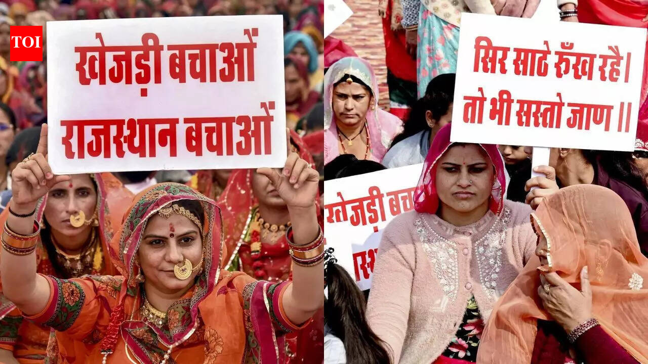 Khejri Bachao Andolan In the heat of Rajasthan’s desert districts, a tree has become the focal point of a widening confrontation. Markets have shut, saints have gone on strike, political rivals have shared protest stages, and thousands have gathered under open skies to demand its protection.What began in Bikaner as a local objection to the alleged felling of khejri trees for solar power projects has since evolved into the ‘Khejri Bachao Andolan’, a statewide campaign pressing for stricter legal safeguards and an immediate ban on cutting the species. The movement has drawn support across party lines, producing a rare moment of political convergence.The khejri, botanically known as Prosopis cineraria and recognised as Rajasthan’s state tree, occupies a distinctive place in the ecology of the Thar desert. Amid the ongoing protests, chief minister Bhajan Lal Sharma, assuring the protection of the khejri, termed the tree as the state’s “Kalpavriksha,” a wish-fulfilling tree in Indian tradition. In an arid landscape where survival is closely tied to ecology, the reference reaffirms the tree’s symbolic and practical importance. For many communities in western Rajasthan, the debate now extends beyond development policy into questions of history, identity and survival. Protestors carried posters featuring a revered proverb in the Bishnoi community: “Sir saanthe rukh rahe to bhi sasto jaan” (If a tree can be saved, even at the cost of one’s head, consider it a bargain). (PTI)How the agitation unfoldedThe present phase of the movement intensified in early February, when over 360 saints and local residents began a hunger strike in Bikaner, demanding an immediate ban on the felling of khejri trees for solar power projects. The protest site was initially the Polytechnic College ground near the Collectorate before shifting to the Bishnoi Dharamshala, where the hunger strike continues.In Bikaner, markets remained closed for hours on Monday after a call by trader associations. Government and private schools in urban areas observed a half-day holiday in solidarity. Thousands gathered at the Polytechnic College ground before marching towards the Collectorate, where organisers announced an indefinite sit-in.Protesters came not only from different districts of Rajasthan but also from Uttar Pradesh, Haryana, Maharashtra and Madhya Pradesh. Organisers said they had arranged food for nearly one lakh participants, with hundreds of volunteers handling logistics. Police deployed additional forces, erected barricades near the Collectorate and kept water cannons on standby. Despite the scale and tensions, the protest remained peaceful. Environmental activists and members of the Bishnoi community participate in the Save Khejri Movement at Polytechnic College, protesting against the proposed cutting of Khejri trees for a solar power plant, in Bikaner. (PTI)Four protesters were admitted to Prince Bijay Singh Memorial Hospital as their health deteriorated during the hunger strike, while several others received medical assistance at camps set up near the site. Mokhram Dharaniya, one of the hospitalised protesters, said, “People are sitting on a hunger strike, including me. Our protest will continue until our demands are met.”The trigger? Solar expansion At the centre of the agitation are allegations that large numbers of khejri trees have been cut to facilitate solar power projects in western Rajasthan. The region has emerged as a hub for renewable energy, given its high solar irradiance and availability of land. While solar development is central to India’s energy transition goals, protesters argue that project implementation has come at the cost of ecologically vital trees.Tensions escalated when the state government announced a restriction on felling khejri trees only in the Jodhpur and Bikaner divisions. Protesters rejected the move as inadequate, demanding a blanket statewide ban. During one address by a government representative, protesters reportedly took away the microphone, insisting on a written assurance. Environmental activists and members of the Bishnoi community take part in the ‘Save Khejri Movement’, protesting against the proposed cutting of Khejri trees for a solar power plant, in Bikaner. (PTI Photo)Minister for skill, employment and entrepreneurship KK Bishnoi and State Animal Welfare Board chairman Jaswant Bishnoi visited the Bishnoi Dharamshala and offered juice to the hunger strikers in an attempt to persuade them to break their fast. The minister said the government was ready to provide a written commitment and appealed to protesters to end the hunger strike. However, saints on the stage refused to withdraw without formal documentation.Agitation leader Parsaram Bishnoi said, “The hunger strike did not end. The government order was incomplete as it failed to cover the entire state.” Former minister Bhanwar Singh Bhati said: “All sections of society participating in the agitation decided to continue until a complete ban on cutting Khejri trees was imposed across Rajasthan.”Storm in the assemblyThe issue has resonated in the Rajasthan Assembly. Congress MLA Dungar Ram Gedar raised the matter during Zero Hour, accusing the government of failing to act despite a persistent two-year protest led by the Bishnoi community in Bikaner. “Khejri being the state tree, there is an urgent need for a strict law to protect it,” Gedar said.Independent MLA Ravindra Singh Bhati stated that the matter was already under discussion in the assembly. “Bhagat Singh (the Indian freedom fighter) said that sometimes a blast is needed to make the voice heard. If it takes gheraoing the Assembly to save khejri, I will be at the forefront,” he said.Chief Minister Bhajan Lal Sharma told the assembly that his government was drafting a conservation law for the khejri tree, which he described as the state’s “Kalpavriksha”. “In August, saints from Bikaner, Phalodi, Jodhpur and Nagaur met me. Following that, I instructed officials to prepare the draft legislation. The process is under way, and it will soon be presented in the assembly,” he said.The chief minister also used the assembly session to defend his government’s broader record, speaking about economic growth, recruitment reforms and water supply projects. However, protesters have maintained that until a formal statewide ban is issued, the agitation will continue.Former chief minister and senior Congress leader Ashok Gehlot expressed support for the public movement, describing the indiscriminate cutting of khejri trees in the name of development as “extremely painful and unacceptable.” He recalled the historical sacrifice associated with the tree and said environmental protection must be prioritised.In a development seen as politically significant, former chief minister Vasundhara Raje publicly backed the movement that has put her own party, the BJP, in the dock.Sharing a photograph of herself worshipping a khejri tree, she wrote, “I also worship the Khejri tree. Rising above politics, we should all come forward to protect it. We must save it. I stand with everyone in the campaign to save the Khejri tree and the Oran (grazing land).” She also quoted a proverb revered in the Bishnoi community: “Sir saanthe rukh rahe to bhi sasto jaan” (If a tree can be saved, even at the cost of one’s head, consider it a bargain).Observers have noted that her intervention has added to political pressure on the state government. Vasundhara Raje shared a photo of herself performing a ritual puja, while pledging cross-party support to protect these trees and associated Oran grazing lands from development threats.The historical memory: Khejarli and Amrita DeviAny discussion of the khejri in Rajasthan inevitably returns to the events of 1730 in the village of Khejarli near Jodhpur. According to historical accounts, 363 members of the Bishnoi community, led by Amrita Devi Bishnoi, sacrificed their lives to prevent the felling of khejri trees ordered for royal construction.The episode, often referred to as the Khejarli massacre, is widely regarded as one of the earliest recorded instances of environmental resistance. Amrita Devi is said to have declared that the loss of her head would be a small price to save a tree. Her sacrifice and that of the others form a cornerstone of Bishnoi identity and environmental ethics in the region. According to historical accounts, 363 members of the Bishnoi community, led by Amrita Devi Bishnoi, sacrificed their lives to prevent the felling of khejri trees ordered for royal construction.Protesters in the current agitation have repeatedly invoked this legacy. Even Ashok Gehlot referred to the sacrifice of 363 individuals, including Amrita Devi Bishnoi, and said their legacy should be honoured.Ecological significanceThe khejri is uniquely adapted to arid (extremely dry) and semi-arid climates. It has a deep root system that allows it to access groundwater and survive prolonged drought. Unlike many other species, it does not compete aggressively with crops and is often grown in agricultural fields in a traditional agroforestry system. An agroforestry system is a land-use practice where trees are grown alongside crops or livestock on the same land to improve productivity and sustainability.Its leaves, known as “loong,” are used as fodder for livestock. Its pods, called “sangri,” are a staple ingredient in traditional Rajasthani cuisine, particularly in the dish Ker Sangri. The wood is used as fuel and timber, while its bark and other parts have been used in traditional medicine. The Khejri tree (Generative image)Ecologically, the tree improves soil fertility by fixing nitrogen, reduces desertification by stabilising sand dunes and provides shade in extreme heat. In regions where annual rainfall is minimal, it plays a crucial role in sustaining both human and animal life.Given these attributes, many in Rajasthan see the khejri not just as a tree but as a symbol of resilience and survival in a harsh environment.Legal framework and demandsCurrently, khejri trees are protected under various forest and environmental regulations, but protesters argue that enforcement is inconsistent and that ambiguities in existing laws create loopholes. Former Luni MLA Mahendra Vishnoi said, “Confusion exists in current laws concerning khejri conservation. The penalties must be precise and severe. Without a fear of the law, this destruction will persist.”Environmental activist Mokhram Dharniya alleged administrative inaction. “The administration has betrayed us repeatedly. Over the past year, we have held numerous protests, receiving assurances each time, while the trees continue to be axed. We will not permit the cutting of khejri anymore,” he said.One of the demands emerging from the agitation is a provision imposing a fine of Rs 1 lakh for violations. Activists have also called for a temporary statewide ban on felling until a comprehensive conservation law is enacted.Spread of the movementThe agitation has extended beyond Bikaner. In Barmer, protesters gathered at the Collectorate, and some youths climbed the gate and raised slogans after police closed the premises. A memorandum addressed to the chief minister was submitted.The movement has also taken on a deeply personal dimension for some families. Following the death of environmental activist Radheshyam Bishnoi in a road accident last year, his mother Ratni Devi and wife Nirma Bishnoi have continued his work and are now on a hunger strike demanding protection for khejri trees. Members of the Bishnoi community during an indefinite hunger strike, demanding a tree protection bill in the ongoing assembly session and a complete ban on cutting of khejri trees, near a Bishnoi Dharamshala, in Bikaner, Rajasthan. (PTI Photo)Meanwhile, reports of illegal logging in other parts of the state, including in the forest area of Bayana subdivision in Bharatpur district, have further fuelled concerns about enforcement.Activists said the issue concerns the entire desert belt, including Jaisalmer, Barmer, Jodhpur, Pali, Jalore, Phalodi, Sriganganagar, and Churu. Protesters alleged that thousands of khejri trees were felled in recent years, largely for infrastructure and solar power projects.Founder of the Khejri Bachao Andolan, Parasram Bishnoi, said the agitation would continue until the state enacts a specific law making the cutting of khejri trees a punishable offence.“Large tracts of desert land are being indiscriminately handed over to solar parks, destroying the local ecosystem. Without legal protection, the desert’s survival is at stake,” Bishnoi told TOI.He added that participation is swelling daily and asserted that the onus now lies on the state government led by chief minister Bhajan Lal Sharma. Bishnoi alleged that khejri trees were uprooted across vast desert areas both in the name of renewable energy projects and by an illegal wood mafia, with little effective oversight.Development versus conservationThe unfolding debate reflects a broader tension between renewable energy expansion and environmental safeguards. Rajasthan is a key state in India’s solar mission. Large tracts of land are being allocated for solar parks, transmission corridors and associated infrastructure. Environmental supporters and members of the Bishnoi community participate in the ‘Save Khejri Movement’ (ANI photo)While renewable energy is seen as essential for climate mitigation, local communities argue that development planning must take into account ecological realities and traditional land-use patterns. The khejri, embedded in agricultural and grazing systems, is not easily replaceable.For many protesters, the demand is not to halt development but to ensure that it does not erode the ecological foundation of desert life.An evolving movementAs the Khejri Bachao Andolan entered its sixth day, its trajectory remains uncertain. The state government has indicated it is drafting legislation. Protesters insist on immediate written assurances and a comprehensive statewide ban.What is clear is that the agitation has tapped into a powerful historical memory and a deeply rooted cultural ethos. The khejri tree stands at the intersection of ecology, economy and identity in Rajasthan. Its fate has become a test case for how the state balances development with conservation in one of India’s most fragile landscapes.Whether the movement results in a new conservation law, stricter enforcement or a recalibration of project implementation, it has already reaffirmed the enduring symbolic power of a tree that many in Rajasthan consider their “Kalpavriksha”.End of ArticleFollow Us On Social MediaVideosPiyush Goyal Says Agriculture Is Self Reliant Sector As India Refuses Farm Import Benefits To USFrom Design To Silicon, India Signals Semiconductor Breakout With Semicon 2.0 RoadmapMP Minister Vijay Shah Finally Apologises For Comment Targeting Op Sindoor Face Col Sofia QureshiTurkey Sides With Pakistan On Kashmir At UN After Sharif’s Rhetoric On India’s ‘Integral’ Territory’Home-Grown Ills’: Islamabad Mosque Blast Triggers Blame Game As India Rejects Pakistan’s BlameEx-US Official Raymond Vickery Says India Outsmarted Donald Trump Chaos By Sticking To Trade ProcessEx-US Official Raymond Vickery Backs India Red Line On Russian Oil As US Trade Deal Drops MentionIndia-US Trade Deal Explained: What The White House Says On Tariffs, Markets And Tech ShiftsPM Modi Calls India-US Trade Pact Framework Great News For Jobs, Make In India And Exports’We Were Preparing For War’: Former DGMO Reveals Inside Story Of India-China Doklam Stand-Off123Photostories6 celebrities who called out social media as ‘toxic’: Tom Holland, Selena Gomez, Kate Winslet, and moreThe ultimate footwear checklist every girl needs in her closet5 mistakes to avoid when investing in under-construction projectsFrom Anil Kapoor to Janhvi, meet ‘ Tu Yaa Main’ actress Shanaya Kapoor’s star relativesChennai airport soars: 80% on-time flights beat private giantsMumbai prepares for faster commute as WEH-BKC connector enters final stageTop 10 iconic Japanese fast foods you need to try at least once7 must-try winter street foods in ChandigarhUpcoming OTT releases for this week: ‘Kohrra Season 2’, ‘The Lincoln Lawyer Season 4,’ and moreTop luxury trekking motorbikes in 2026: Premium rides for rugged adventures123Hot PicksBudget 2026Gold Silver PricesParliament Budget SessionGCC Unified Visa 2026Income Tax CalculatorPublic holidays February 2026Bank Holidays februaryTop TrendingSuper Bowl TrophyCooper Kupp WifeKayla NicoleSuper Bowl LX TicketOliver RowlandJustin GaethjeLIV GolfLiam Paro vs Paddy Donovan Net WorthWinter Olympics 2026NBA Trade Update