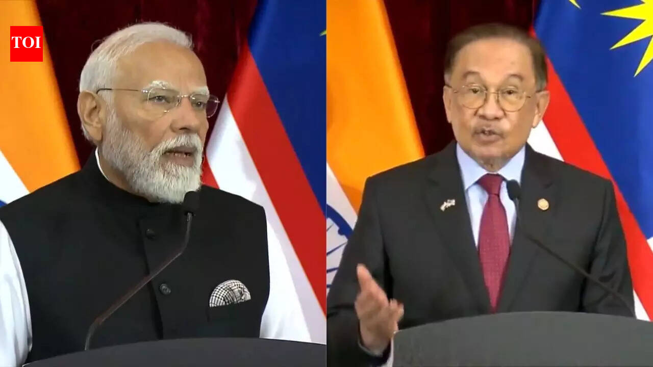 NEW DELHI: Prime Minister Narendra Modi received a ceremonial welcome and Guard of Honour at the Perdana Putra building in Putrajaya on Sunday, marking a key moment in his two-day official visit to Malaysia. The reception followed his arrival in Kuala Lumpur a day earlier, when Malaysian Prime Minister Anwar Ibrahim personally welcomed him at the airport.The visit comes months after India and Malaysia elevated their ties to a Comprehensive Strategic Partnership in August 2024. Bilateral talks between the two leaders are expected to focus on defence and security, economic cooperation, innovation, clean energy, semiconductors, and people-to-people ties, amid a shifting global and regional security landscape.Ceremonial welcome at Perdana PutraPM Modi was accorded a red-carpet welcome at Perdana Putra, the Malaysian Prime Minister’s office complex, accompanied by a Guard of Honour. The ceremony featured traditional music and dance performances, reflecting the shared cultural heritage between the two countries.Malaysian Minister of Human Resources Ramanan Ramakrishnan and Deputy Foreign Minister Lukanisman bin Awang Sauni were present at the reception.Reflecting on the welcome, PM Modi posted on X: “Deeply touched by the warm welcome extended by my friend, Prime Minister Anwar Ibrahim at the airport. I look forward to our conversations and to further strengthening the bonds of friendship between India and Malaysia.”Joint outreach to Indian communityFollowing the arrival ceremony, PM Modi and PM Anwar Ibrahim travelled together in the same vehicle to attend an Indian community event in Kuala Lumpur. The Malaysian Prime Minister also participated in the programme.Sharing an update on X, PM Modi wrote, “Celebrating the India-Malaysia people-to-people connect! PM Anwar Ibrahim and I are heading to the community programme in Kuala Lumpur.”Bilateral talks on wide-ranging agendaThe two leaders are scheduled to hold delegation-level talks on Sunday, with discussions expected to result in multiple agreements aimed at expanding cooperation across sectors.In his departure statement before the visit, PM Modi said: “The historic ties between India and Malaysia have seen steadfast progress in recent years. I look forward to my discussions with Prime Minister Anwar Ibrahim and further enhancing our comprehensive strategic partnership.””We will aim to deepen our defence and security ties, enhance our economic and innovation partnership, and expand our collaboration into new domains.”External affairs ministry spokesperson Randhir Jaiswal said the visit carries a “rich agenda and will give a major boost to the special partnership between India and Malaysia”.”The visit is expected to impart significant momentum to our close & multi-faceted partnership,” he added.Modi-Anwar delegation-level talksDuring delegation-level talks, PM Modi underlined the growing depth of bilateral ties, saying: “I am fully experiencing the height and depth of this friendship, and for this, I am deeply grateful to you. It is my great fortune that as Prime Minister, I have had the opportunity to visit Malaysia for the third time, and our friendship is such that I am getting the opportunity to meet you for the fourth time during your tenure. This itself demonstrates our momentum and dynamism. The pace and depth that our bilateral relations have achieved in recent years are truly inspiring. I sincerely thank you for your invaluable contribution in this regard…”Cooperation expanding across key sectorsHighlighting sectoral cooperation, PM Modi said: “Today, our cooperation is deepening in every sector, from agriculture and manufacturing to clean energy and semiconductors. We are also important partners in skill development and capacity building. Our defence and security cooperation is also continuously strengthening.”He also congratulated Malaysia on its ASEAN role, adding: “I once again congratulate you on your successful chairmanship of ASEAN. We are confident that with Malaysia’s cooperation, our relations with ASEAN will deepen and expand further.”Diaspora a living bridgeEmphasising people-to-people ties, PM Modi said: “The true strength of our relationship lies in our people-to-people ties. The nearly 3 million Malaysian citizens of Indian origin are a living bridge between our two countries…”Referring to his interaction with the Indian diaspora, he added: “Yesterday, I also had the opportunity to meet with members of the diaspora with you. It was a very special experience, and I saw the personal respect and affection that the diaspora has for you, which was evident yesterday. I felt a sense of pride.”Terrorism, global instability and shared prosperityPM Modi said cooperation between friendly nations was essential in the current global environment. “The support of friendly nations is crucial in our fight against terrorism. We firmly believe that the prosperity of India and Malaysia is intertwined. In this environment of global instability, it is essential for India and Malaysia, two maritime neighbours, to utilise the full potential of our relationship.”He added: “The core message of my visit today is very clear: India wants to work with Malaysia to take our relationship to a new level and expand cooperation in every possible area…”What PM Modi said at the joint press statement At the joint press interaction, Prime Minister Modi described India-Malaysia ties as unique and deeply rooted. “India-Malaysia relations are really special. We are maritime neighbours. For centuries, there have been deep ties between people of our two countries. Today, Malaysia is the second biggest nation in the world that has Indian origin population. Our civilisations are connected to shared cultural heritage and democratic values.” He said bilateral relations had gathered fresh momentum in recent years, crediting Malaysian Prime Minister Anwar Ibrahim for his role in strengthening ties. “In the past few years, our relations have picked up a new pace. My friend, PM Anwar Ibrahim has had a special contribution towards this. Cooperation between us in energy, infrastructure and manufacturing has strengthened. Mutual investment in digital economy, biotech and IT has increased. Tourism and people-to-people ties have also deepened. Drawing inspiration from these achievements, we have decided to bring in unprecedented speed and depth in our partnership.” PM Modi said Malaysia was a priority destination, marking it as his first foreign visit of 2026. “…Last year, I could not come to Malaysia for the ASEAN Summit, but I had promised my dear friend that I would visit Malaysia at the earliest. For my first foreign visit of 2026, I have come to Malaysia.” Outlining future areas of cooperation, PM Modi said security and emerging technologies would be key pillars. “In the security sector, we will strengthen cooperation in counter-terrorism, intelligence sharing and maritime security. We will also make defence cooperation more comprehensive. Along with AI and digital technologies, we will further advance our partnership in semiconductor, health and food security. The CEO forum organised today has thrown open new opportunities for trade and investment. We will pave a path to economic transformation through strategic trust.” What Malaysian PM Anwar Ibrahim said at the joint press statement Prime Minister Anwar Ibrahim praised India’s economic rise and said Malaysia stood to benefit by expanding cooperation with New Delhi, particularly within the ASEAN framework. “India is growing by leaps and bounds, which is one spectacular rise in the international economic trade scene and therefore Malaysia in the ASEAN context certainly benefits immensely if we could secure more ways and opportunities to collaborate with India to extending beyond the .59 billion that we achieved in 2025. One remarkable feat is this decision to use local currency as far as possible…” He stressed the importance of education and academic exchanges, noting India’s growing global standing in higher education. “Education remains pivotal. Many Malaysians were educated in India, and there is a growing number of Indian students in Malaysia too, but since the last decade or so under the premiership of my good friend Prime Minister Modi, you have seen the spectacular recognition of Indian centres of excellence in education. That’s not only comparable but many of them have achieved outstanding recognition beyond the known institutions in the West. Therefore, we would certainly explore this to increase the number of students in the disciplines and fields to study in India…” Anwar Ibrahim also flagged tourism and connectivity as priority areas, linking them to visa liberalisation and increased air links. “… Tourism and connectivity are areas that we will have to give more emphasis. We have seen this spectacular increase during the past year, and we hope to benefit from Malaysia Truly Asia and Incredible India through visa liberalisation and increase air connectivity. I have been to India several times and covered hundreds of places, and I still think that I have not covered India. It’s too huge, Prime Minister, and it’s an amazing country to visit, to learn the history, the culture, the arts, other than the new advancement in the technology…” On regional and global issues, he said discussions with PM Modi reflected trust and candour. “In terms of regional and international issues, I must express my appreciation because in my discussions with Prime Minister Modi, it is not just normal bias platitudes and diplomatic exchanges. It is an exchange between true friends, full of trust and understanding…” The Malaysian Prime Minister also praised PM Modi’s role in global peace efforts and announced support for opening a new Indian consulate. “I must also take this opportunity to express my regards and thanks to PM Modi for his firm commitment to support all peace efforts throughout the world, be it in Ukraine, Russia or in the case of the Middle East, particularly in Gaza, his commitment to support the peace process is unequivocal and certainly I must therefore express my appreciation. As a sign of our good relations, I immediately have agreed to support the decision of the Government of India to open a consulate of India in Kota Kinabalu, Sabah…”About the AuthorTOI News DeskThe TOI News Desk comprises a dedicated and tireless team of journalists who operate around the clock to deliver the most current and comprehensive news and updates to the readers of The Times of India worldwide. With an unwavering commitment to excellence in journalism, our team is at the forefront of gathering, verifying, and presenting breaking news, in-depth analysis, and insightful reports on a wide range of topics. The TOI News Desk is your trusted source for staying informed and connected to the ever-evolving global landscape, ensuring that our readers are equipped with the latest developments that matter most.”Read MoreEnd of ArticleFollow Us On Social MediaVideos’Reasons For Reducing Russian Oil Imports Are…’ Foreign Expert Explains India-US Trade FrameworkIndia Reiterates Energy Security Priority, Signals Russia Oil Imports Will ContinueGhaziabad Sisters’ Deaths: Father’s Three Marriages Add Twist To Probe“Deal Favours US farmers” Opposition Attacks India-US Trade FrameworkFrom Tamil Pride To Global Trust: How PM Modi Used Culture To Reset India-Malaysia RelationsPM Modi In Kuala Lumpur Says India Malaysia Ties Are Rising, Unveils IMPACT Vision For Asia”To Benefit Farmers….” Shivraj Singh Chouhan Big Claim On India-US Trade DealPiyush Goyal Says Agriculture Is Self Reliant Sector As India Refuses Farm Import Benefits To USFrom Design To Silicon, India Signals Semiconductor Breakout With Semicon 2.0 RoadmapMP Minister Vijay Shah Finally Apologises For Comment Targeting Op Sindoor Face Col Sofia Qureshi123Photostories6 electrical mistakes that can increase your power billHow to make fiber-rich Oats and Sooji Idli for breakfast8 baby names you will hear everywhere in the next 5 yearsExclusive – Yuvika Choudhary on The 50: I took a break after my daughter’s birth to be there for her; now it’s time for me to return as a working momHow Taylor Swift turned fashion into her signature storytelling powerMukaish to Rabari: Underrated embroidery techniques in India that deserve more attention7 most colourful birds of Indian forestsThe 50: Major Fights That Grabbed Attention5 luxury sports cars that combine comfort with extreme powerThomas Edison once said, “I’ve not failed, I’ve just found 10,000 ways that won’t work”: 4 lessons it teaches students123Hot PicksBudget 2026Gold Silver PricesParliament Budget SessionGCC Unified Visa 2026Income Tax CalculatorPublic holidays February 2026Bank Holidays februaryTop TrendingIndia vs USA LiveCooper Kupp WifeKayla NicoleSuper Bowl LX TicketOliver RowlandJustin GaethjeLIV GolfLiam Paro vs Paddy Donovan Net WorthWinter Olympics 2026NBA Trade Update
