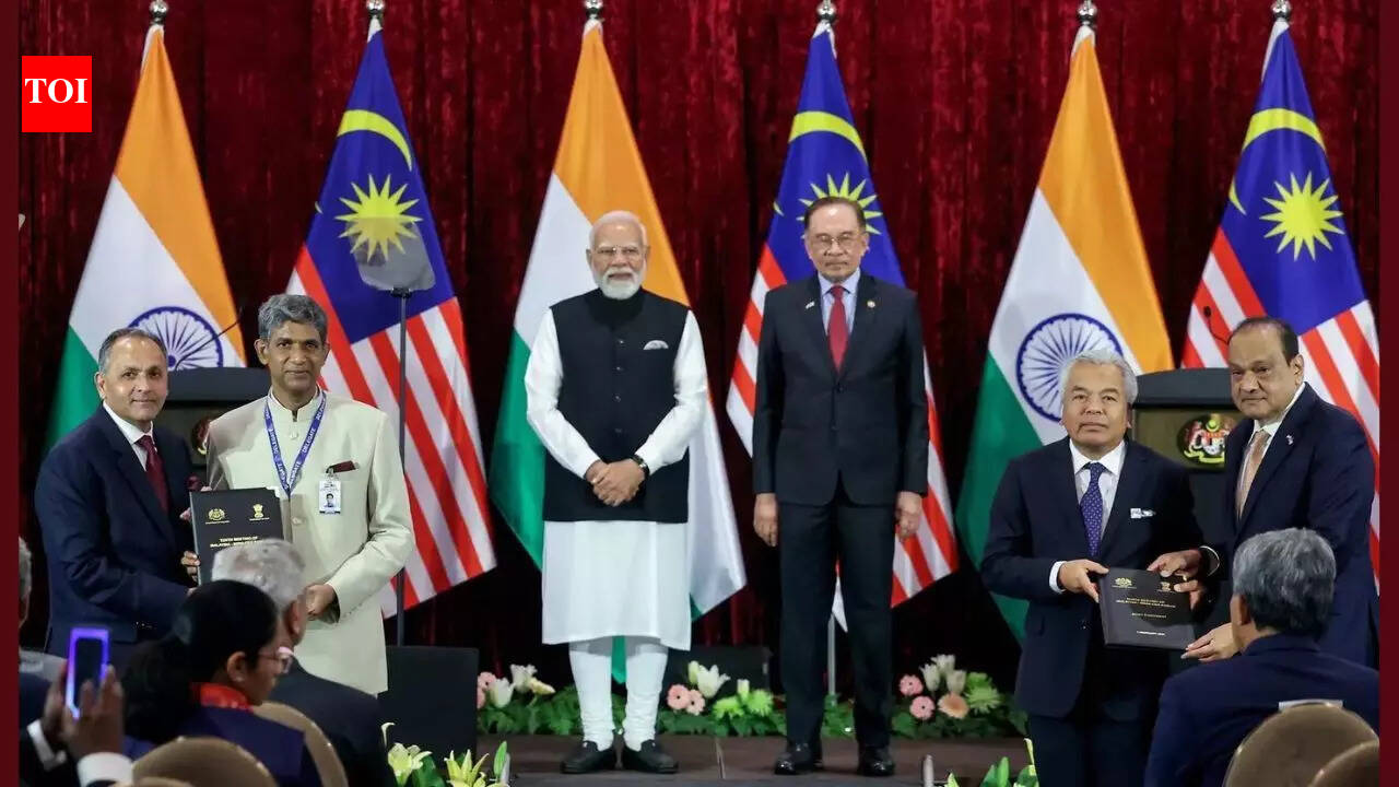 Prime Minister Narendra Modi with Malaysian Prime Minister Anwar Ibrahim witnesses the exchange of MoUs between India and Malaysia, in Kuala Lumpur on Sunday. (DPR PMO/ANI Photo) KUALA LUMPUR: India and Malaysia inked 11 MoUs in what was described by both Anwar Ibrahim and Narendra Modi as a “critical, strategic and vital exchange” for reinforcing the Comprehensive Strategic Partnership, at Seri Perdana, the official residential complex of the Malaysian PM.Key agreements include Exchange of Notes (EoN) on semiconductors, a sector where both countries are aggressively partnering to boost the value chain, including AI and R&D. At the press briefing after the signing of the deals, an agreement between India’s NPCI International Ltd (NIPL) and Malaysia’s PayNet was announced. “Strategic Ties And Trade Strengthened”: PM Modi Exchanges MoUs With Malaysian PM “It is not yet operational owing to some necessary technical alignments,” said P Kumaran, secretary, East. He added that there is also a broader project for multi-point connectivity called Project Nexus; which India, Malaysia, Singapore and a few other countries in the region are working on. This will give direct connectivity from one country to all the other countries partaking in the Nexus.On the question of a timeline for operationalising the settlement of trade in local currencies, Kumaran said, “It is a matter of priority for both sides and discussions are ongoing between the two regulatory bodies, RBI and Bank Negara. We are going to be working very actively on this in the coming few months.”On defence, the two PMs emphasised their intent to work closer and expressed satisfaction at the outcomes of the Malaysia-India Defence Cooperation Committee (MIDCOM) and its subcommittees, including the terms of reference on establishment of a Strategic Affairs Working Group (SAWG) and Su-30 Forum.Importantly, India’s three-decade experience with Su-30s and its proximity to Malaysia makes it the best country for its upgrade and maintenance. This also encompasses a broader defence industrial agenda beyond transactional procurement.Other agreements include areas like disaster management, the fight against corruption, healthcare, training in Ayurveda, anti-terrorism, UN Peacekeeping as well as the Framework Agreement on the Big Cats Alliance. The two sides have also agreed to collaborate on social security through a pact between Malaysia’s social security organisation and India’s Employees’ State Insurance Corporation.End of ArticleFollow Us On Social MediaVideos‘Few Political Elements Trying To Distort’: Goyal Explains India-US Trade Deal, Slams Opposition‘India Has A Preference Over…’: Piyush Goyal On US Trade Deal, Trump’s ‘Russian Oil’ Claim‘Embarrassed Himself’: Gaurav Gogoi Slams Assam CM Himanta Sarma Over ‘Pakistan Links’ Allegation‘1.25 Crore Hindus In Bangladesh’: RSS Chief Mohan Bhagwat Issues Big Unity CallUkraine to Gaza: Malaysia PM Anwar Ibrahim hails PM Modi’s unwavering global peace pushGogoi’s wife Elizabeth worked for Pakistani agent Ali Tauqeer Sheikh: Assam CM Himanta Biswa Sarma‘India’s Stand on Terrorism Is Clear’: PM Modi Speaks Firmly During Malaysia Visit”Strategic Ties And Trade Strengthened”: PM Modi Exchanges MoUs With Malaysian PM’Reasons For Reducing Russian Oil Imports Are…’ Foreign Expert Explains India-US Trade FrameworkIndia Reiterates Energy Security Priority, Signals Russia Oil Imports Will Continue123Photostories5 Vastu-approved plants you should bring home today for prosperity7 brutal truths about starting a business no one warns you about5 effective ways to keep spiders away from your home and garden (third is a magical remedy!)Top 6 cheapest destinations to travel in India in 2026The one-sided friendship problem: Why so many adult friendships feel draining now8 types of kadhi from across India to try for lunchScarlett Johansson net worth: Inside the USD 165 million fortune of Marvel’s ‘Black Widow’ starFrom Bad Bunny, Green Day to Charlie Puth: Full list of Super Bowl 60 performersFrom a massive living room to lavish bedrooms: A look at Samay Raina’s luxurious housePM Narendra Modi’s Panch Prana goal and the role of Shatavari and it’s importance in traditional Indian kitchens123Hot PicksBudget 2026Gold Silver PricesParliament Budget SessionGCC Unified Visa 2026Income Tax CalculatorPublic holidays February 2026Bank Holidays februaryTop TrendingFortnite Love EventBoston Celtics vs New York KnicksLindsey Vonn InjurySuper Bowl LX TicketSuper Bowl PredictionsJustin GaethjeLIV GolfLiam Paro vs Paddy Donovan Net WorthWinter Olympics 2026NBA Trade Update