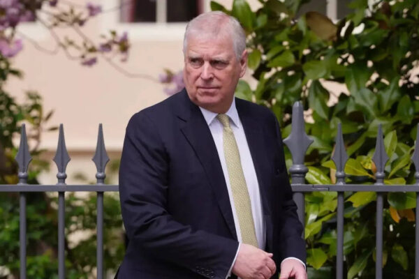‘Creepily crouching over’: Lawmaker claims redacted photo shows Epstein trafficking victim with ex-Prince Andrew