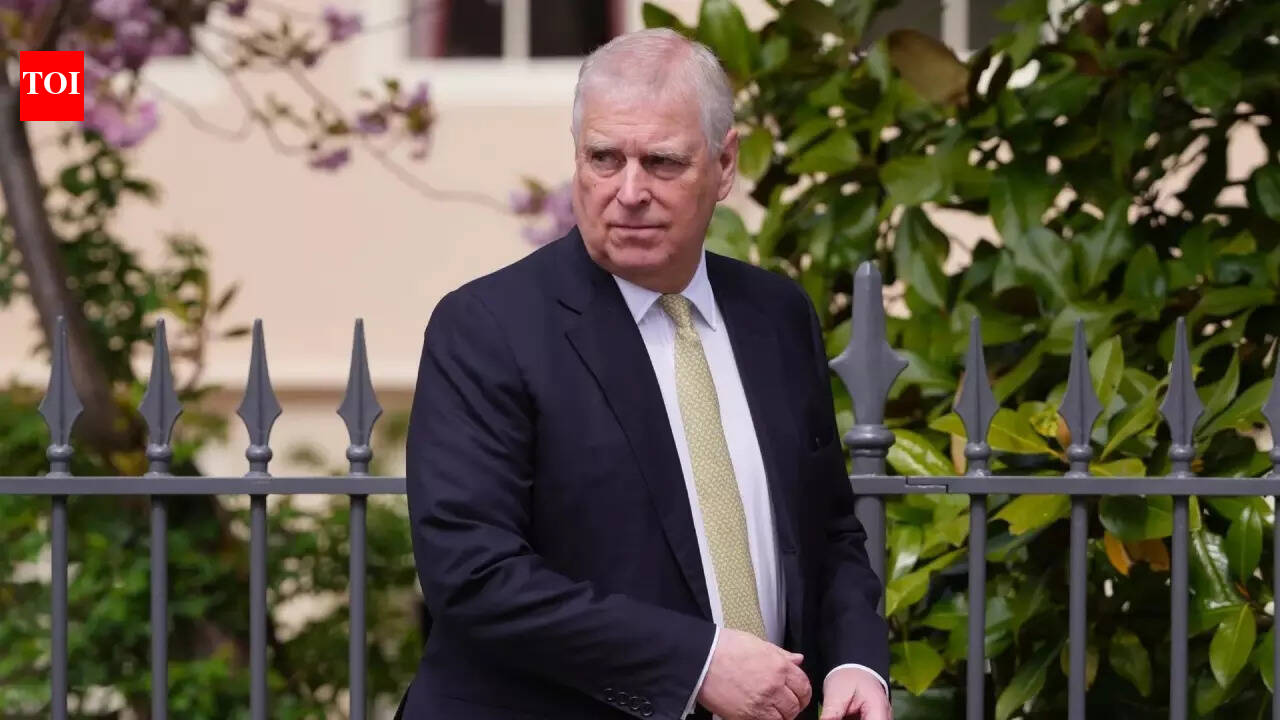 ‘Creepily crouching over’: Lawmaker claims redacted photo shows Epstein trafficking victim with ex-Prince Andrew